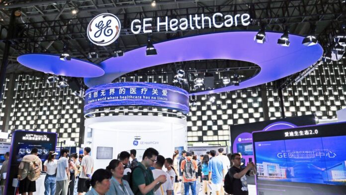 <strong>GE HealthCare Technologies</strong> (GEHC) has had a rough year, and investors have been asking whether the selling is over, or whether more losses lie ahead.
Needham & Company gave investors their opinion on <strong>Sept. 22</strong>. The firm started coverage of GEHC with a <strong>Buy rating</strong> and a <strong>$93 price target</strong>, pointing to a <strong>roughly 44% increase</strong> from the Monday, Sept. 21, close <strong>near $64.81</strong>.
The stock had already <strong>lost about 20%</strong> of its value since January, due to tariff costs, a struggling division, and weakness from China.
But on the day of the note, shares <strong>climbed close to 2.5%</strong>, and the stock <strong>closed at $66.09</strong> on Wednesday, Sept. 23. Needham argued that the market has already priced in a worst-case scenario, and the potential reward from here looks larger than the remaining downside.
Needham’s $93 GE HealthCare target and what it actually means
Needham analyst <a href="https://www.tipranks.com/experts/analysts/david-saxon">David Saxon</a> started GEHC coverage with a bull case.
“Our Bull-Bear analysis of GEHC suggests shares are largely pricing in a Bear case, which creates an attractive risk/reward,” Saxon wrote in his note to clients, according to <a href="https://www.cnbc.com/2026/09/22/buy-the-dip-on-ge-healthcare-says-needham.html">CNBC</a>.
Saxon set a $93 target price because he believes the stock should be valued at <strong>17 times</strong> its expected 2027 earnings. Right now, investors are paying a much cheaper price of <strong>about 12.6 times</strong>.
Right now, GE HealthCare is <strong>30% cheaper</strong> than its competitors. Similar companies trade at an average price of <strong>18.8 times</strong> their expected earnings.
Needham expects GE HealthCare to catch up to its rivals over the next year. They believe this discount will disappear because the company is on track to grow its sales by <strong>around 4% to 6%</strong> and its profits by <strong>7% to 9%</strong> over the next 12 months. Its Advanced Imaging Solutions division is also expected to rapidly accelerate by 2027.
Needham is not the only one supporting the bull case. TheStreet data shows that <strong>10 of 15 analysts</strong> covering GEHC rate the shares a <strong>Buy</strong>, with a <a href="https://www.thestreet.com/quote/GEHC">consensus price target</a> of <strong>$80</strong>. That means most of Wall Street believes in the company’s fundamentals.
GE HealthCare’s imaging systems, including MRI, CT, and ultrasound machines, sit at the center of Needham’s bull case for a 44% rebound.<a href="https://www.gettyimages.com/detail/1517817619">CFOTO / Getty Images</a>
What actually pushed GE HealthCare stock lower this year
GE HealthCare does a lot of business in China, but hospitals there have temporarily stopped buying new scanning equipment.
CFO Jay Saccaro said on the fourth quarter earnings call that “tariffs accounted for about half of the year-over-year gross margin decline,” a profit loss the company has been offsetting with pricing and cost actions, <a href="https://finance.yahoo.com/news/ge-healthcare-q2-earnings-call-044905596.html">Yahoo Finance</a> reported.
The company’s Patient Care Solutions division, which makes monitoring and anesthesia equipment, also posted weaker first-half results. <a href="https://investor.gehealthcare.com/news-releases/news-release-details/ge-healthcare-reports-second-quarter-2026-financial-results">GE HealthCare</a>‘s management confirmed in its second-quarter 2026 press release that PCS is under strategic review, which often points to a possible sale or spin-off.
<strong>More Health Stocks:</strong>
<strong><a href="https://www.thestreet.com/investing/stocks/morgan-stanley-flags-amgens-edge-after-heart-drug-rival-stumbles">Morgan Stanley flags Amgen’s edge after heart-drug rival stumbles</a></strong>
<strong><a href="https://www.thestreet.com/investing/stocks/why-morgan-stanley-likes-gileads-hiv-prevention-play">Why Morgan Stanley likes Gilead’s HIV prevention play</a></strong>
<strong><a href="https://www.thestreet.com/investing/stocks/nvo-novo-nordisk-ceo-doustdar-considers-direct-nyse-listing">Novo Nordisk CEO opens the door to major move for U.S. investors</a></strong>
GE HealthCare beat expectations in the second quarter, growing revenue by <strong>5.75%</strong> year over year to <strong>$5.3 billion</strong> and topping earnings-per-share estimates by <strong>9.09%</strong>.
On the call, CEO Peter Arduini said the company had “delivered record orders and backlog in the second quarter, with orders growth across every segment.” However, investors wanted stronger assurance about when the China and PCS issues would change, so shares kept falling.
How GE HealthCare makes money and why the valuation looks cheap
GE HealthCare designs and sells the imaging machines that hospitals rely on, including MRI scanners, CT machines, ultrasound units, and X-ray systems. It also produces contrast agents, which are the injectable dyes that make scans clearer, along with patient monitoring equipment and pharmaceutical diagnostics.
The company separated from <strong>General Electric</strong> in early 2023 and now serves customers in <strong>more than 160 countries</strong>.
<strong><a href="https://www.thestreet.com/investing/stocks/jim-cramer-nuvation-bio-stock-pure-spec-nuvb">Related: Jim Cramer sends strong 5-word message on surging biotech stock</a></strong>
Roughly half of its revenue comes from long-term recurring streams such as service contracts and consumables, which keep cash flow steady, even when new equipment orders slow down.
That steady revenue stream is why the current valuation looks unusual. <a href="https://www.insidermonkey.com/news/ge-healthcare-gehc-is-down-28-and-wall-street-is-starting-to-buy-is-the-selloff-finally-over-1843144/">Insider Monkey</a> noted that GEHC “is priced below its peers despite dealing with imaging that hospitals cannot operate without,” adding that new AI features on the company’s scanners help defend its pricing power.
Two upcoming dates that will test the turnaround call
Two upcoming dates will support Needham’s bull case. On <strong>Oct. 23</strong>, investors who own the stock before the deadline will qualify for a cash payout. While this dividend payment is small at a <strong>0.21% yield</strong>, it proves that the company’s management is dedicated to rewarding shareholders, even while navigating a tough recovery.
Also, on <strong>Oct. 30</strong>, GE HealthCare is scheduled to release its 2026 third-quarter results. Investors will be watching for improvement in China orders, an update on the PCS strategic review, and any margin recovery from tariff mitigation actions. If the company beats growth expectations, it will prove Saxon right.
While the potential gain looks great for new investors, the risks still remain. If China’s economy stays weak or the company’s internal restructuring disappoints, the stock could drop back down to its <strong>$58.75 low</strong>.
Because the analyst’s $93 target is just a forecast, a safer strategy might be to buy in slowly around the Oct. 30 report, rather than investing all your money at once.
<strong><a href="https://www.thestreet.com/investing/stocks/eli-lilly-lly-merida-biosciences-2-88-billion-acquisition">Related: Lilly looks beyond obesity with $2.88B autoimmune buyout</a></strong>