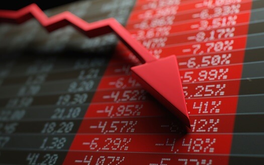 <!-- WordPress post title: Alphabet Stock Falls 7%, Tesla Drops 14.5% as Wall Street Punishes AI Spending Suggested category: Stocks -->
Alphabet and Tesla reported earnings after the market closed on July 22, and both were punished in the same trading session for the same reason. Alphabet shares fell <strong>7.13% to $317.69</strong> on July 23 despite stronger-than-expected revenue and an 82% increase in Google Cloud sales. Tesla dropped <strong>14.52% to $319.69</strong> after its capital expenditure surged and free cash flow turned negative.
For nearly two years, markets frequently treated larger artificial intelligence budgets as evidence of future growth. The July 23 selloff suggests investors are beginning to apply a different test. Spending on data centres, chips, autonomous systems and computing infrastructure still supports the long-term AI thesis, but it is increasingly being judged against the cash those investments consume and the returns they are expected to generate.
The clearest comparison is in the annual spending plans. Alphabet now expects 2026 capital expenditure of between <strong>$195 billion and $205 billion</strong>, placing the midpoint near $200 billion. Tesla expects to spend more than <strong>$25 billion</strong>, close to three times its roughly $8.5 billion of capital expenditure in 2025. In both cases, investors focused less on the size of the opportunity and more on the immediate claim those programmes place on cash flow.
Alphabet and Tesla Fell in the Same Session
Alphabet produced results that would ordinarily support a higher stock price. Quarterly revenue reached <strong>$119.80 billion</strong>, exceeding the approximately <strong>$116.93 billion</strong> expected by analysts. Google Cloud revenue rose <strong>82% year over year</strong>, providing further evidence that demand for AI computing, enterprise cloud services and related infrastructure remains strong.
The stock nevertheless fell more than 7%. The market reaction was driven by Alphabet’s decision to raise its full-year capital expenditure forecast to between $195 billion and $205 billion from a previous range of $180 billion to $190 billion. The revision added approximately $15 billion at the midpoint.
Alphabet spent <strong>$44.9 billion</strong> on capital expenditure during the quarter. That investment contributed to quarterly free cash flow of <strong>negative $5.9 billion</strong>, shifting attention away from the revenue beat and toward the financial cost of expanding AI capacity.
Tesla experienced an even larger decline during the same July 23 session. Its shares lost 14.52% and closed at $319.69 after the company reported its first negative free cash flow quarter in more than two years.
Tesla’s quarterly capital expenditure increased <strong>142% year over year</strong> to approximately <strong>$5.8 billion</strong>. The company also guided investors to expect more than $25 billion of capital expenditure for the full year as it funds AI computing, autonomous driving, robotaxi development, robotics, battery production and manufacturing capacity.
The companies entered the quarter with different businesses and different financial profiles. The market nevertheless reached a similar conclusion on both: revenue growth and long-term AI ambitions did not fully offset concern about the speed at which investment was consuming cash.
The Capex Numbers Changed the Earnings Story
Alphabet’s earnings beat established that demand was not the immediate problem. Google Cloud was growing rapidly, total revenue exceeded expectations and the company remained positioned at the centre of the AI infrastructure buildout.
The issue was the amount of capital required to support that growth. At the midpoint, Alphabet’s revised forecast implies approximately $200 billion of capital expenditure in 2026. That is an infrastructure programme large enough to alter how investors evaluate the entire company, even when operating businesses continue expanding.
Tesla’s spending programme is smaller in absolute terms but larger relative to its recent history. A full-year budget above $25 billion would be close to three times its 2025 capital expenditure. Investors are therefore being asked to assign value not only to Tesla’s current vehicle business but also to projects whose financial returns depend on future adoption of autonomous transport, robotics and AI services.
Neither reaction proves that the investments are mistaken. Alphabet may need enormous computing capacity to protect its position in search, cloud computing and generative AI. Tesla may need to spend heavily before robotaxis and humanoid robots can become commercial businesses. The market is instead asking how long shareholders must fund those plans before the spending produces measurable returns.
Negative Free Cash Flow Was the Trigger
Capital expenditure does not reduce reported revenue, but it directly affects free cash flow. That distinction explains why Alphabet’s revenue beat failed to protect the stock.
Investors can tolerate rising expenditure when operating cash flow comfortably covers the investment and leaves significant cash available for buybacks, acquisitions or balance-sheet growth. The interpretation changes when capital expenditure pushes quarterly free cash flow below zero.
Alphabet’s negative $5.9 billion figure made the cost of its AI programme visible in a single number. Tesla’s first negative free cash flow quarter since early 2024 produced a similar warning. Both companies are investing in projects that may generate substantial future revenue, but both asked investors to accept weaker present cash generation in exchange for that possibility.
The selloff indicates that Wall Street may be placing a higher burden of proof on incremental AI spending. Announcing a larger data-centre programme is no longer automatically read as a bullish signal. Investors increasingly want evidence that earlier investment is improving margins, revenue growth and cash generation before rewarding the next increase.
The Read-Through for Nvidia and AI Infrastructure Stocks
The reaction matters for companies supplying the AI buildout. Nvidia, AMD, Broadcom, Arista Networks, Vertiv, Super Micro Computer and data-centre operators have benefited from expectations that hyperscalers will continue purchasing processors, networking systems, cooling equipment and power infrastructure at increasing rates.
Alphabet’s higher forecast is positive for suppliers because it confirms continued demand. The stock reaction is more complicated. Should investors continue punishing customers for the effect of AI spending on free cash flow, management teams may eventually face pressure to moderate investment or demonstrate stronger returns from existing capacity.
That creates a distinction between near-term supplier revenue and the valuation applied to that revenue. Semiconductor and infrastructure companies may continue reporting strong orders while their customers face greater scrutiny over the economics of those purchases.
The same question applies to quantum-computing and early-stage AI infrastructure companies whose valuations depend on spending expected years into the future. When markets become less willing to reward capital-intensive growth without near-term cash generation, companies with limited revenue and high infrastructure requirements can be repriced more aggressively than established suppliers.
FinanceFeeds previously examined the valuation debate surrounding <a href="/nvidia-nvda-stock-302-bull-case-152-bear-case/">Nvidia, including a $302 bull case and a $152 bear case</a>. Alphabet and Tesla’s declines reinforce the central issue in that debate: AI demand may remain strong while investors become less willing to pay any price for exposure to it.
What Would Prove the AI Capex Thesis Wrong?
The remaining hyperscaler earnings reports will test whether July 23 represented a broader market shift or a reaction to company-specific cash-flow figures.
If the next group of large technology companies raises capital expenditure, reports weaker free cash flow and still sees its shares hold or rally, the claim that Wall Street has turned against AI spending would be too broad. Investors may simply have judged Alphabet and Tesla’s spending increases as excessive relative to their individual results.
If additional companies report strong revenue, increase AI budgets and suffer similar stock declines, the repricing thesis becomes harder to dismiss. That pattern would indicate that investors are applying a new condition to the AI trade: capital expenditure must produce visible operating leverage rather than only promise future market leadership.
Alphabet and Tesla did not fall because investors stopped believing in artificial intelligence. They fell because two of the largest listed companies showed, in the same earnings cycle and the same market session, how expensive the race has become. The next stage of the AI trade may therefore be determined less by who spends the most and more by who converts that spending into cash first.