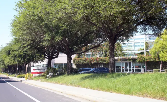 Broadcom has agreed to lend Anthropic up to $42 billion so the lab can lease tensor-processing-unit capacity, a commitment sitting in Anthropic’s IPO filing and <a href="https://www.reuters.com/business/broadcom-lend-anthropic-up-42-billion-lease-its-chips-filing-says-2026-10-01/">reported by Reuters on October 1, 2026</a>. The $42 billion is a loan ceiling, not a purchase order. The notes can convert into Anthropic shares, and Anthropic told the filing it does not expect any of them to be sold before the IPO. On that news, Nasdaq had Broadcom at $352.25 at 8:49 a.m. ET, up $1.06, or 0.30%, from Wednesday’s $351.19 close. A facility sized to about a third of a $125.2 billion, five-year TPU lease moved the stock 0.30%.
Set against the share count, $42 billion is about $8.75 a share on the roughly 4.8 billion shares <a href="https://tradesmith.com/stockdata/AVGO:NASDAQ/statistics">TradeSmith shows against the September 30 close</a>, or 2.5% of $351.19. The stock already sits 27% under its June 2 closing high of $481.57 because the customer was already inside the guide. In September Broadcom put AI semiconductor revenue at about $115 billion for fiscal 2027 and about $230 billion for fiscal 2028, and Reuters reported with today’s filing that Anthropic is expected to be the largest compute customer in 2027. The incremental fact is who writes the cheque. Broadcom is offering to finance the customer that is supposed to make it the largest line in the custom-chip book, and to hold that customer’s equity if the notes convert. Equipment vendors did this with telecom carriers into 2000. The revenue looked like demand. A slice of it was the vendor’s own credit.
<strong>Quick take.</strong> Nothing has been drawn. The 0.30% premarket gain prices a $42 billion option as an option. The move that would actually change AVGO is already on the Street: a $531.85 average target, 51% above $351.19, from 50 analysts on <a href="https://www.marketscreener.com/quote/stock/BROADCOM-INC-42668543/">MarketScreener</a>.
Key facts
<strong>$42 billion</strong> loan ceiling from Broadcom to Anthropic for infrastructure, disclosed in the IPO filing — <a href="https://www.reuters.com/business/broadcom-lend-anthropic-up-42-billion-lease-its-chips-filing-says-2026-10-01/">Reuters, October 1, 2026</a>
<strong>$125.2 billion</strong> five-year TPU lease. The convertible would cover about a third of it — Reuters, October 1, 2026
<strong>$161.2 billion</strong> of Broadcom-related equipment leases, largely non-cancellable, inside at least <strong>$518 billion</strong> of infrastructure commitments, about 80% of which Anthropic says it cannot walk away from — <a href="https://www.reuters.com/world/anthropic-ipo-prospectus-lays-bare-deep-dependence-big-tech-partners-2026-09-29/">Reuters, September 29, 2026</a>
<strong>$351.19</strong> official close on September 30, down <strong>$3.91</strong>, or <strong>1.10%</strong>. Premarket on October 1 at 8:49 a.m. ET: <strong>$352.25</strong>, up <strong>0.30%</strong> — <a href="https://www.nasdaq.com/market-activity/stocks/avgo">Nasdaq</a>
<strong>$481.57</strong> highest close in the April–September window, on June 2. Wednesday’s close is 27% below it — Nasdaq daily closes
<strong>$115 billion</strong> and <strong>$230 billion</strong>: Broadcom’s AI semiconductor revenue figures for fiscal 2027 and fiscal 2028 — Reuters, October 1, 2026
<strong>$531.85</strong> average analyst target, <strong>51.4%</strong> above the September 30 close, 50 analysts — MarketScreener
<strong>$8.75 a share</strong>: $42 billion divided by about 4.8 billion shares, equal to <strong>2.5%</strong> of $351.19 — FinanceFeeds calculation from the TradeSmith share count and the Nasdaq close
What the filing commits, and what it does not
Reuters, which saw the prospectus, describes a relationship that runs through three pipes at once: Broadcom supplies compute, Broadcom is on the lease, and Broadcom has agreed to lend. Amazon, the comparison Reuters draws, mostly provides cloud infrastructure and distribution for Claude. Broadcom is in the silicon, the rental contract and the credit. That is why the filing can say Anthropic stands to become the largest customer in the chip-design business next year and, in the same document, warn that the relationship creates conflicts over access to computing power.
The mechanics are narrower than the headline. Broadcom may designate a financing partner. The instruments Anthropic would issue are convertible into Anthropic shares. Anthropic deposited cash into a restricted account for Broadcom’s benefit in April 2026 and may have to add more. The company also warned that a payment or performance default could make a substantial share of the lease obligations due at once, and could block use of the $42 billion facility to pay them. A backstop that disappears in the scenario it was written for is a different instrument from a committed loan.
The $125.2 billion, five-year TPU lease is the obligation the convertible is sized against. Forty-two divided by 125.2 is 33.5%, which is the “about a third” in the Reuters account. Alphabet’s Google and Broadcom have collaborated on several generations of those TPUs. Anthropic said in April that an expanded partnership would give it multiple gigawatts of next-generation TPU capacity beginning in 2027. On the March earnings call, chief executive Hock Tan said Anthropic was “off to a very good start in 2026” on a gigawatt of Google TPU compute and that 2027 demand was “expected to surge in excess of 3 gigawatts,” <a href="https://www.cnbc.com/2026/04/06/broadcom-agrees-to-expanded-chip-deals-with-google-anthropic.html">CNBC reported on April 6</a>.
Mizuho’s Vijay Rakesh, in a note CNBC cited that week, estimated Broadcom would take in $21 billion of AI revenue from Anthropic in 2026 and $42 billion in 2027. The April announcement itself carried no dollar figure. Five months later the financing ceiling in the prospectus is the same $42 billion. The ledgers are different. One was a one-year revenue estimate. The other is an undrawn, multi-year loan cap against a lease. They share a number, and that is the point skeptics have reached for. If the revenue hope and the credit ceiling are the same size, the customer’s ability to pay and the vendor’s willingness to lend are no longer independent facts.
A separate stack is already closed. In June, Apollo and Blackstone raised $35 billion to finance Anthropic’s lease of Google chips that Broadcom helps develop, aimed first at about a gigawatt and, as a partnership, at as much as 20 gigawatts through 2028, <a href="https://www.ft.com/content/c49e0eff-0776-4103-8eaf-1b049fbf9d3f">the Financial Times reported</a>. Broadcom backstopped interest on the two senior tranches. In August, Bloomberg, via <a href="https://www.reuters.com/technology/broadcom-seeks-more-than-60-billion-latest-ai-debt-deal-bloomberg-news-reports-2026-08-20/">Reuters</a>, said a further Broadcom-linked debt talk could run past $60 billion. Today’s $42 billion is the prospectus ceiling. It is neither the June loan nor that August discussion.
The wider Anthropic math, from <a href="https://www.reuters.com/world/anthropic-ipo-prospectus-lays-bare-deep-dependence-big-tech-partners-2026-09-29/">Reuters on September 29</a>, is what the ceiling is being asked to sit under. Revenue in 2025 rose about twelvefold to nearly $4.6 billion. Operating losses topped $8 billion. Two customers each accounted for 12% of revenue, and 47% of sales ran through Amazon’s and Google’s cloud marketplaces. The lab is seeking about $2 trillion. FinanceFeeds set out what that ask implies per share in <a href="https://financefeeds.com/anthropic-ipo-price-prediction-1221-per-share/">the September 30 IPO price piece</a>.
Who answered, and who stayed quiet
Broadcom did not comment. Anthropic declined to comment. That is the whole of the corporate response Reuters could get on the morning the filing detail came out. The document is doing the talking, which is what a confidential prospectus is for, and it talks against its own author on two points: the lab may not be able to get the computing power it needs because its supplier is also its lender, and Broadcom’s pricing and hardware decisions could determine whether the infrastructure shows up.
Robert Leitao, managing partner of Rothschild & Co., told Reuters: “It feels that there’s quite a concentrated bet right now on two companies being able to generate enough revenues to support all the financing that’s happened.” Anthropic is one of those payers. A vendor that also lends to it has doubled its exposure to the same revenue.
Jay Goldberg of Seaport Research put the same point on Nvidia. “Nvidia is putting in place a massive amount of its balance sheet, and Broadcom is having to follow suit,” he told Reuters. In this filing the version is a convertible in front of a TPU lease whose silicon Broadcom co-designs with Google. The buyer is a lab preparing a listing that could value it at $2 trillion, and the circularity is now in an IPO document.
Google designed the TPUs. Broadcom is the partner that helps build them. Anthropic is the lessee, and Amazon and Google are already its investors, distributors and suppliers. The rival-lab version of the silicon relationship is <a href="https://financefeeds.com/openai-jalapeno-chip-nvidia-blackwell-broadcom/">OpenAI’s Jalapeño chip on Broadcom silicon</a>. Anthropic’s filing adds the credit leg. Google would be lessor and investor. Broadcom would be lender and, if the notes convert, shareholder.
Hock Tan’s April line remains the last detailed public description of this customer, and it was a volume statement, not a promise to advance $42 billion. The September guide, parsed in <a href="https://financefeeds.com/broadcom-avgo-stock-prediction-715-bull-216-bear/">the $715 bull case and $216 bear case</a>, already had Anthropic as a central 2027 TPU buyer. After a mid-September report that the lab wanted to slow the buildout, Tan said the AI revenue targets had not changed. Today’s filing agrees with that sentence. The skeptical reading agrees with it too: the target holds because the vendor will help pay.
What $42 billion does to a $351 share
Broadcom daily closes, 1 April to 30 September 2026. The last mark is the September 30 close of $351.19. Source: Nasdaq. October 1 premarket, 8:49 a.m. ET, was $352.25, up 0.30%, and is not a point on this line.
From the April 1 close of $313.49 to Wednesday’s $351.19, AVGO is up 12.0%. The high close in the window was $481.57 on June 2, and Wednesday finished $130.38 under it. September 30 itself opened at $356.90 and closed at $351.19, down 1.10% on 19.8 million shares. The filing story broke the next morning. The only print that belongs to it is the premarket, up $1.06.
At about 4.8 billion shares, Wednesday’s close is a market value near $1.69 trillion. The ceiling is 2.5% of that. TradeSmith had the shares down 4.60% over the month into September 30, a larger move than the entire facility, on no filing. The bullish figure that would actually reprice the name was already published against that close: MarketScreener’s average target of $531.85 is $180.66, or 51.4%, higher, and it requires the $115 billion and $230 billion AI figures to be believed. Confirming the customer, and adding an undrawn convertible, does not insert a new $180. It asks the existing target to survive a credit question.
The template for how this stock treats good news is the September quarter, covered in <a href="https://financefeeds.com/broadcom-avgo-earnings-bullish-580-bearish-345/">Broadcom’s fiscal third-quarter report</a>: revenue up 86% to $29.6 billion, AI semiconductor revenue of $16.7 billion, and the shares lower because the next guide sat a shade under consensus. A facility that funds a lease the guide already counted will not re-rate AVGO. A disclosure that the lease needs the vendor’s balance sheet might.
FigureWhat it isShare-price reading
$42 billionUndrawn loan ceilingAbout $8.75 a share, 2.5% of $351.19, if someone capitalises the ceiling. It is not drawn.
$352.25Oct 1 premarket, 8:49 a.m. ETThe actual move after the Reuters story: +0.30%.
$531.85Average target, 50 analysts+51.4%. This is the move the guide implies, and it predates this morning.
$481.57June 2 closing highWednesday’s close is 27% below it. That gap is the bear case already in the tape.
$115 billionFiscal 2027 AI semiconductor guideThe $42 billion ceiling is 36% of one year of that guide, and it finances a five-year lease.
The conflict the prospectus puts in writing
Anthropic’s own disclosure is the regulatory document that matters this morning, because no market regulator had published a response to it by the premarket print. The lab told prospective holders that Broadcom’s double role, hardware supplier and financing partner, creates “potential conflicts of interest” that might affect Anthropic’s access to computing power. It warned that Broadcom’s decisions on pricing and hardware could determine whether Anthropic can procure enough infrastructure. Those sentences are the company’s compliance language, written under securities-law liability, not a blog post.
If Anthropic misses a payment or a performance test, a large piece of the lease can become due immediately, and the $42 billion facility may not be available to meet that bill. The restricted cash posted in April already puts Broadcom ahead of the customer’s flexibility. About 80% of the $518 billion buildout, on the September prospectus reporting, is non-cancellable or payable whether the capacity is used. This lease is one more obligation that does not shrink when demand does.
Anthropic’s case for a valuation of about $2 trillion is that compute is the binding constraint and that locking it up is the strategy. The same pages put the lock-up across Google, Amazon, Microsoft and Broadcom, put two customers at 24% of 2025 revenue, and leave many large customers off long contracts. The lab is short-dated on revenue and long-dated on cost. A convertible that can make Broadcom a shareholder adds a related party to a register that already includes the cloud vendors. Reuters’ September reading put their marketplace fee near 16 cents per dollar of those sales.
The conversion price is not in the public account of the filing. Dividing $42 billion by a $2 trillion valuation and calling the result an ownership stake invents a strike the excerpt does not give. An option with no published strike is another reason the shares moved 0.30%.
The same morning, in a TIME interview, President Trump said he “might” take stakes in OpenAI and Anthropic of the kind the United States took in Intel. The tape on that comment, and Intel’s $120.23 close, is in <a href="https://financefeeds.com/intel-up-3-7-percent-at-120-trump-hottest-stock/">the companion piece</a>. A federal holder beside Broadcom in a converted note is not in this filing. It does put the lab’s register on the political page on the day the chip lender was disclosed.
Where the share price goes from $351
Three paths follow from the documents, and each has a number on it.
The first is that the premarket is the move. The notes stay unsold through the IPO, the customer was already in the September guide, and the guide survived Tan’s comment that a slower buildout had not changed the targets. On that chain AVGO keeps trading the next quarterly increment. Wednesday’s session, down 1.10% with no Anthropic headline, was three times this morning’s reaction.
The second path is the Street’s 51% gap, from $351.19 to the $531.85 average target. It does not require the convertible to be drawn. It requires fiscal 2027 AI semiconductor revenue near $115 billion and the $230 billion figure for 2028 to stay believable. The causal test is the next earnings call. If Tan repeats both numbers and still calls Anthropic the largest 2027 compute customer, the target survives. If he qualifies either sentence because the financing is what makes the customer largest, the target is the price that moves, not the $8.75 of loan ceiling.
The third is Leitao’s credit path. Anthropic’s 2025 revenue was nearly $4.6 billion, against operating losses above $8 billion and a lease stack in the hundreds of billions. The $42 billion is the slice Broadcom has offered to bridge. If a default accelerates the leases and shuts the facility, the revenue guide and the credit guide break together. The share-price expression of that risk is the distance already traded: $130.38 a share from the June 2 close to Wednesday, about $625 billion of market value, given back while the story was still that Anthropic would be the big customer.
A 0.30% premarket gain says the relationship was known in outline. The new information is the cap, the convertibility and the conflict language, and those wait on a public conversion price. Until then AVGO is a guide story at $351, 27% under its June high and 51% under the average target.
FAQ
How much will Broadcom lend Anthropic?
Up to $42 billion, to finance infrastructure spending, under an arrangement in Anthropic’s IPO filing as reported by Reuters on October 1, 2026. Anthropic said it does not expect the notes to be sold before the IPO is completed. The ceiling is about a third of a $125.2 billion, five-year lease of TPU computing capacity. It is a cap, not a drawn balance.
Did AVGO stock rise on the $42 billion news?
The only print after the story broke was the premarket. At 8:49 a.m. ET on October 1, Nasdaq showed AVGO at $352.25, up $1.06, or 0.30%, from the September 30 close of $351.19. That prior close was itself down 1.10% on the day. The filing was not public during Wednesday’s session, so the 1.10% decline is not a reaction to it.
How much could this move Broadcom’s share price?
Counted as equity value, which overstates a loan, $42 billion is about $8.75 a share, or 2.5% of the $351.19 close, on roughly 4.8 billion shares. The larger figures already attached to the stock are elsewhere. The average analyst target is $531.85, 51% higher. The June 2 closing high was $481.57, 27% above Wednesday’s close. Neither gap was created by this morning’s headline.
Will Anthropic be Broadcom’s largest custom-chip customer?
Reuters reported that Anthropic stands to be the largest customer in the chip-design business next year and the largest compute customer in 2027, beside a guide of about $115 billion of AI semiconductor revenue in fiscal 2027 and about $230 billion in fiscal 2028. The $42 billion is the financing offered against the lease, not the revenue line.
Is this the same $42 billion as Anthropic’s reported loss, or the June private-credit deal?
No. Coverage of the prospectus has put Anthropic’s 2025 net loss near $42 billion, a figure dominated by non-cash financing marks, while Reuters’ September account of operating losses was “topped $8 billion.” Separately, Apollo and Blackstone closed a $35 billion chip-financing in June that Broadcom backstopped at the senior level. Today’s $42 billion is a Broadcom lending ceiling in the IPO filing. Three different $40-billion-scale numbers are now in circulation. They are not one obligation.
Can the loan turn into Anthropic equity?
Reuters reported that the debt instruments could be converted into Anthropic shares, and that Broadcom could designate a financing partner. The conversion price is not in the published account of the filing. Anthropic is seeking a valuation of about $2 trillion. Until a strike price is disclosed, that equity kicker cannot be marked to the share price, which is consistent with a 0.30% premarket move.