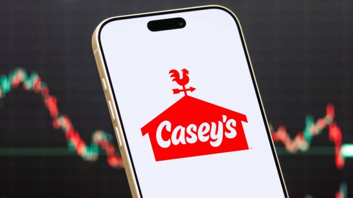 Casey’s General Stores has spent much of the last few years building a <strong><a href="https://investor.caseys.com/">business </a></strong>that looks increasingly different from the traditional gas station. Pizza, prepared food, and a growing rewards program have helped make the convenience retailer a destination even when customers are not filling up.
The company operates nearly 3,000 stores across 19 states and has roughly 11 million Casey’s Rewards members.
That momentum did not spare the stock after its latest earnings report. Casey’s General Stores (CASY) shares dropped roughly 14% following fiscal first-quarter results, even as earnings and EBITDA posted double-digit growth. Bank of America thinks the selloff has created an opportunity.
Bank of America analyst Lisa K. Lewandowski reiterated a Buy rating on Casey’s in a note given to TheStreet, although she lowered the firm’s price objective to $875 from $975. The new target still implies about 39% upside from the $629.03 share price listed in the Sept. 9 note.
The lower target reflects what BofA described as near-term remodeling noise, a cautious U.S. consumer, and a recent re-rating across convenience-store stocks. Still, the firm called Casey’s a top-tier operator and said the company’s underlying growth trends remain solid.
Casey’s earnings give BofA reasons to stay bullish
Casey’s reported fiscal first-quarter diluted <strong><a href="https://www.sec.gov/Archives/edgar/data/726958/000072695826000084/q1fy2027earningspressrelea.htm">earnings </a></strong>of $7.37 per share, up 27.7% from a year earlier. Net income climbed 27.1% to $273.7 million, while EBITDA increased 17.1% to $485.1 million. Inside same-store sales rose 3.2%, with the company posting a 42.2% inside margin.
Fuel was another bright spot for profits. Same-store gallons sold declined 0.3%, but fuel <strong><a href="https://investor.caseys.com/news-releases/news-release-details/caseys-announces-first-quarter-results-3">gross profit</a></strong> increased 19.6% to $446.9 million as Casey’s generated a fuel margin of 47.8 cents per gallon.
The company left its fiscal 2027 outlook unchanged. Casey’s still expects inside same-store sales growth of 2% to 5%, an inside margin above 42%, and EBITDA growth of 8% to 10%. It also expects to open at least 120 stores through acquisitions and new construction.
More Gas Station Stocks
<strong><a href="https://www.thestreet.com/automotive/pain-at-the-gas-pump-rises-as-middle-east-violence-worsens">Pain at the gas pump rises as Middle East violence worsens</a></strong>
<strong><a href="https://www.thestreet.com/retail/gas-station-giant-gives-arko-up-on-471-stores">Gas station giant gives up on 471 stores </a></strong>
<strong><a href="https://www.thestreet.com/automotive/average-gas-prices-in-the-month-set-a-new-high-for-august">August sees a dubious record on gasoline prices</a></strong>
For BofA, one of the biggest near-term pressure points is also part of the long-term opportunity. Casey’s is converting acquired CEFCO stores, and some locations need to close for roughly four to six weeks while kitchens and other upgrades are installed.
BofA estimates the remodeling work reduced first-quarter inside same-store sales by about 25 basis points and fuel sales by about 50 basis points. The analyst expects that drag to continue through the fiscal third quarter.
The payoff could be meaningful once those stores reopen. BofA said remodeled locations typically see sales rise about 30% from prior levels, with many gaining foodservice capabilities for the first time. Casey’s ended the first quarter with 2,959 stores after adding 21 locations and closing or divesting six during the quarter.
Casey’s General Stores (CASY) shares dropped roughly 14% following fiscal first-quarter results.<a href="https://www.gettyimages.com/detail/2281342653">Cheng Xin / Getty Images</a>
BofA sees foodservice supporting Casey’s growth
Prepared food remains an important part of the bull case. Casey’s has been pushing deeper into higher-margin foodservice, including whole pizzas and chicken wings, while expanding its rewards program and converting more acquired stores to the Casey’s format.
The company’s new <strong><a href="https://investor.caseys.com/news-releases/news-release-details/caseys-announces-new-three-year-strategic-plan-0">three-year strategic plan</a></strong> calls for continued expansion of food and beverages, store growth, and greater operating efficiency. Casey’s said in June that it had added more than 500 stores under its previous three-year plan before laying out its next phase of growth.
BofA also raised its earnings estimates despite cutting the price target. The firm now forecasts EPS of $21.77 in fiscal 2027, $24.06 in fiscal 2028, and $26.64 in fiscal 2029, all slightly above its previous estimates.
Lewandowski’s $875 target is based on 18.9 times projected fiscal 2028 enterprise value to EBITDA. That is a premium to convenience-store peers, but BofA argues Casey’s deserves it because of its geographic footprint, logistics network, cost controls, and exposure to higher-margin foodservice.
For investors, BofA has become more conservative on how much it is willing to pay for Casey’s shares even as its expectations for the underlying business have edged higher. The stock’s sharp post-earnings decline has widened the gap between its current price and the firm’s new target.
<strong><a href="https://www.thestreet.com/retail/7-eleven-rival-caseys-quietly-killing-a-cefco-convenience-store-brand">Related: 74-year-old convenience store chain closing all locations</a></strong>