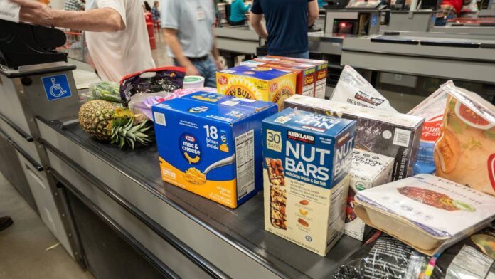<a href="https://www.thestreet.com/quote/COST">Costco</a> Wholesale (<a href="https://www.thestreet.com/quote/COST">COST</a>) shares slipped on Monday, June 29, as one of <a href="https://www.thestreet.com/dictionary/w/wall-street">Wall Street</a>'s top retail analysts delivered an attention-worthy message on the stock.Bernstein analyst <a href="https://www.tipranks.com/experts/analysts/zhihan-ma">Zhihan Ma</a> named <strong>Costco</strong> and discount chain <strong>Dollar General</strong> (<a href="https://www.thestreet.com/quote/DG">DG</a>) her top retail picks for the second half of 2026. Earlier this week, she raised her Costco price target to <strong>$1,194 from $1,192</strong> and kept her <strong>outperform</strong> rating.That target sits well above COST's<strong> Thursday, July 2, close of $951.67</strong>. Even after climbing <strong>more than 11% since January</strong>, the stock still has room to run.Ma's call boils down to a simple idea. While <a href="https://www.thestreet.com/dictionary/i/inflation">inflation</a> keeps squeezing household budgets, Costco keeps finding ways to turn that squeeze into an advantage.Why Bernstein sees Costco outrunning the rest of retailMa's optimism about Costco starts with a view on shoppers that most retail analysts share right now.Energy prices tied to the Middle East crisis have started easing, according to <a href="https://www.tipranks.com/news/costco-stock-cost-crowned-top-retail-pick-for-the-rest-of-2026-heres-why">TipRanks</a>. However, she still <strong>expects inflation to pressure shoppers</strong> as higher packaging and fertilizer costs work through supply chains. Add in the threat of fresh tariffs, and lower-income households will continue struggling while wealthier shoppers keep hunting for deals.
Costco Wholesale has outpaced much of the retail sector in 2026, even as inflation weighs on household budgets.<a href="https://www.shutterstock.com/image-photo/tigard-usa-mar-24-2025-staffed-2629265175">Tada Images/Shutterstock</a>
Costco's growth engine keeps hummingCostco tends to thrive in exactly this kind of environment. Ma pointed to the retailer's recent <strong>double-digit sales growth</strong>, much of it fueled by <strong>traffic at Costco's gas stations</strong> as drivers search out <strong>cheaper fuel</strong>."Although gas inflation is starting to moderate, we expect Costco to generate about 6-7% comparable sales growth, excluding gas and foreign exchange, which, coupled with the prospect of a special dividend, should support the stock in the near term," Ma wrote, according to <a href="https://www.tipranks.com/news/costco-stock-cost-crowned-top-retail-pick-for-the-rest-of-2026-heres-why">TipRanks</a>.Costco's own numbers are doing the heavy liftingBernstein's call isn't happening in a vacuum.Costco's fiscal third-quarter net sales <strong>climbed 11.6% to $69.15 billion</strong>, according to the company's <a href="https://www.sec.gov/Archives/edgar/data/909832/000090983226000046/costex9918-k52826.htm">SEC</a> earnings release. <strong>Total revenue reached $70.53 billion</strong>, topping Wall Street's forecast. Net income also <strong>jumped 15% to $2.19 billion</strong>, or <strong>$4.93 per diluted share</strong>.Membership income and the dividend storyMembership fee income, the recurring, high-margin revenue that props up Costco's business model, <strong>rose 10.7% to $1.37 billion</strong>. Executive memberships, the pricier tier that signals deeper loyalty, <strong>grew 9.6% to 41.2 million</strong>. CEO <a href="https://investor.costco.com/governance/board-of-directors/person-details/default.aspx?ItemId=f0450829-b19b-4fc4-ac2e-a32ad9dc9234">Ron Vachris</a> also told investors the company logged its <strong>five best gas-volume weeks ever</strong><strong>to close the quarter</strong>. This happened as drivers sought lower prices amid the conflict in the Middle East, according to <a href="https://www.cnbc.com/2026/05/28/costco-cost-q3-2026-earnings.html">CNBC</a>.<strong><a href="https://www.thestreet.com/retail/walmart-nuclear-power-bet-perishable-distribution">Related: Walmart makes unusual nuclear power bet</a></strong>Costco sweetened its dividend too, lifting the quarterly payout <strong>13% to $1.47 per share</strong> in April. On tariffs, Vachris said Costco has begun <strong>filing refund claims</strong> tied to the Supreme Court's ruling striking down certain import levies. Proceeds are designated to keep member prices low rather than pad margins.How Bernstein's target stacks up against the rest of Wall StreetMa isn't the only analyst betting big on Costco. Price targets across Wall Street span a wide range, and Bernstein's $1,194 sits near the very top of that pack.<strong>Where major firms stand on Costco stock</strong>:<strong>Bank of America:</strong> $1,200, buy rating<strong>Bernstein:</strong> $1,194, outperform rating<strong>Goldman Sachs:</strong> $1,159, buy rating<strong>JPMorgan Chase:</strong> $1,110, overweight rating<strong>Raymond James: </strong>$1,100, outperform rating<strong>Citi:</strong> $1,020, neutral rating<strong>Truist Financial:</strong> $1,011, hold rating
Source: MarketBeat
Put together, Wall Street's <a href="https://www.thestreet.com/quote/COST">consensus price target</a> lands at <strong>$1,103.66</strong>, implying <strong>about a 17% increase</strong>, according to data covering 24 analysts. Sixteen rate the stock a buy, seven say hold, and just one recommends selling. This is a rare level of agreement for a stock trading at <strong>roughly 40 times</strong> profits.What could still derail the Costco bullish caseNone of this makes Costco a sure buy. The stock's <strong>price-to-earnings ratio near 40</strong> shows investors are already betting on years of strong performance. <strong>More Retail Stocks:</strong><a href="https://www.thestreet.com/investing/stocks/costco-makes-moves-amid-shaky-economy"><strong>Wall Street expects Costco to surge 16%, amid macro volatility</strong></a><a href="https://www.thestreet.com/retail/dollar-general-ceo-bitter-reality-economy-high-income-shoppers"><strong>Dollar General CEO exposes bitter reality about today's economy</strong></a><a href="https://www.thestreet.com/investing/why-costco-has-outpaced-the-nasdaq-for-five-years"><strong>Why Costco Has Outpaced the Nasdaq for Five Years</strong></a>That high bar means any slip in comparable sales or membership renewals could hurt the stock more than it would a cheaper retailer.Investors watching for the next catalyst should track <strong>Costco's July sales report</strong> and any update on the <strong>special dividend</strong> Ma flagged. A payout announcement could give the stock a fresh jolt, much like it did last time. For now, buying at current levels means betting that Bernstein's math holds up, and that Costco's loyal members keep opening their wallets. This is even as the broader economy stays uncertain.<strong><a href="https://www.thestreet.com/investing/stocks/costco-stock-price-shocks-market-despite-major-blowout-quarter">Related: Costco stock price shocks market despite major blowout quarter</a></strong>