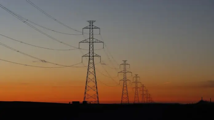 Energy has been the best-performing corner of the market this month, and almost every explanation of why is wrong. The sector ETFs rallied - XLE gained 7.6% and XOP 8.1% over 30 days against the S&P's 3.1%, per <a href="https://stockanalysis.com/etf/xle/">stockanalysis.com</a> - but the four large names underneath tell four completely different stories. <strong>Cameco (CCJ) closed at $99.03, Constellation (CEG) at $278.68, EQT at $54.06 and Vistra (VST) at $146.68</strong> on 12 August. Over twelve months those same four returned <strong>+26%, −18%, +5% and −30%</strong>. Same sector, same AI-power narrative, and a 56-point spread between best and worst.
That dispersion is the actual finding, and it kills the laziest trade in the market right now. "Buy energy because AI needs electricity" has been repeated so often it sounds like analysis, but it produced a 26% gain in one name and a 30% loss in another over the identical period. The thesis was right about demand and useless about selection. What separated the winners from the losers was not exposure to AI power - all four have it - but whether the company sells a commodity whose price rose, or sells electricity into markets where prices did not.
Key facts
<strong>$99.03 / $278.68 / $54.06 / $146.68</strong> - closing prices for CCJ, CEG, EQT and VST on 12 August 2026 - <em>stockanalysis.com</em>
<strong>+26% / −18% / +5% / −30%</strong> - twelve-month total price change for the same four - <em>FinanceFeeds calculation from daily closes</em>
<strong>+7.6% and +8.1%</strong> - one-month gains for XLE and XOP, against +3.1% for SPY
<strong>+33.7% and +38.5%</strong> - year-to-date gains for XLE and XOP, making traditional energy the year's real winner
<strong>−7.2%</strong> - Vistra's one-month move, the only large name in the group that fell while the sector rallied
<strong>−26.8% to −33.3%</strong> - how far CCJ, CEG and VST sit below their 52-week highs
<strong>49%</strong> - Cameco's stake in Westinghouse, held alongside Brookfield
<strong>21</strong> - reactors operated by Constellation, the largest nuclear generator in the United States
Four large energy names over twelve months, indexed to 100. Cameco finished +26%, Vistra −30%. Source: stockanalysis.com.
Cameco (CCJ) at $99.03 - the one that worked
Cameco is the only name of the four that is meaningfully higher over twelve months, at +26%, and it got there by being a miner rather than a generator. Uranium spot prices have been strong, and a producer with volume sells into that directly. Where utilities have to negotiate rates, a commodity producer simply banks the price.
The Westinghouse stake is what makes it more than a mining stock. Cameco owns 49% alongside Brookfield, which gives it exposure to reactor technology and servicing as well as fuel. If the nuclear buildout that everyone is forecasting actually happens, Cameco earns twice from it - once selling the uranium, once building and servicing the plants.
The caution is that the stock is up 9.8% in a month and only +0.5% year to date, which means the twelve-month gain was largely earned earlier and has been given back and rebuilt since. At 26.8% below its 52-week high, it is not cheap on a recovery basis so much as mid-range. Uranium equities are also more volatile than the underlying commodity, and this one has already had its re-rating.
Constellation (CEG) at $278.68 - the quality name that de-rated
Constellation is the largest nuclear generator in the United States with 21 reactors, and it is the name most directly attached to the AI-power thesis through corporate power purchase agreements: hyperscalers contracting directly for nuclear electricity on multi-year terms. It is also down 23.9% year to date and 32.5% below its high.
That gap between narrative and price is the most interesting thing in this group. The PPA story is real - it is the single cleanest way for a technology company to buy clean, firm power at scale - and the market has still marked the stock down by a third. Consensus has earnings growing 13% in 2027 and nearly 29% in 2028, which implies the de-rating is about the path rather than the destination.
Constellation is the one name here with existing cash flows, an operating fleet and contracted demand. Compared with the pre-revenue end of the same theme - our analysis of <a href="https://financefeeds.com/nuscale-smr-stock-prediction-18-bull-4-50-bear/">NuScale, which booked $75,000 of revenue last quarter and just registered a $750m share sale</a>, sets the contrast starkly - it is a fundamentally different proposition wearing the same label.
EQT at $54.06 - the quiet structural story
EQT is the largest natural gas producer in the United States, and it is the name with the most under-discussed thesis in the group. As MarketBeat put it in a recent segment, "US energy demand for 20 years was flat" - a statement that is no longer true, and the whole investment case follows from that reversal.
The argument runs that gas, not nuclear, is what actually powers the next five years of AI infrastructure, because it is the only firm generation that can be built on the timeline data centres need. The same segment was blunt about it: "the only way for us to win the AI race in the next 5 years is natural gas." Power plant construction is driving a production ramp of 20-30%, against two decades of flat demand.
The stock reflects almost none of that: +5% over twelve months, +1.1% year to date, and 20.8% below its high, with the lowest volatility of any name in this group. That combination - a structural demand shift with a modest drawdown and unexcited pricing - is the most conventionally attractive setup of the four. It is also the least exciting, which is probably why it is priced this way.
Vistra (VST) at $146.68 - the one that kept falling
Vistra is the outlier and deserves the attention its price action is getting. It fell 7.2% over the past month while every other name in the group rose, is down 30% over twelve months, and sits 33.3% below its high. Notably, it did this on the second-highest relative trading volume in the group, so the decline is not neglect - it is active selling.
Vistra is an independent power producer, which means its economics depend on merchant power prices and the spread between fuel costs and electricity prices rather than on regulated returns. That model is superb when power prices rise and punishing when they compress. A stock falling on rising volume while its entire sector rallies is usually telling you something specific about the business rather than the theme, and that divergence is worth understanding before treating the drawdown as an opportunity.
What the dispersion actually teaches
Line the four up and a pattern emerges that has nothing to do with AI:
Company12-monthWhat it really sellsPrice exposure
Cameco (CCJ)+26%Uranium, plus 49% of WestinghouseCommodity price, directly
EQT+5%Natural gas at scaleCommodity price, directly
Constellation (CEG)−18%Nuclear electricity under contractContracted rates
Vistra (VST)−30%Merchant powerSpark spreads
The two names that rose sell a commodity into a market that set the price for them. The two that fell sell electricity, where the price is negotiated, regulated or spread-dependent. AI demand raised the volume of electricity needed; it did not automatically raise the margin on selling it. That is the distinction the sector-wide narrative flattens, and it explains a 56-point performance gap that no amount of thesis-level enthusiasm would have predicted.
It also suggests where to look next. If AI power demand is real and persistent, the pressure eventually reaches the generators too - contracts reprice, spreads widen, and the names that de-rated get their turn. That is the bull case for Constellation and Vistra, and it is a case about timing rather than about whether the demand exists.
There is a second lesson buried in the one-month numbers. Over 30 days the group moved together - CCJ +9.8%, EQT +8.7%, CEG +8.2%, with only Vistra dissenting at −7.2%. Over twelve months they diverged by 56 points. Short windows manufacture the illusion that a sector trades as a block; long windows reveal that it does not. Anyone sizing a position off a strong month is measuring correlation that the longer record says is temporary.
The sector ETFs make the same point from the opposite direction. XLE and XOP delivered the year's best returns at +33.7% and +38.5%, yet carry the lowest relative trading volume of anything measured here. The money is chasing the AI-power single names while the returns came from the diversified vehicles nobody is discussing. That gap between where attention goes and where performance came from is the most consistent feature of energy in 2026.
How these fit alongside the names we already cover
These four are the large-cap, cash-generating end of the energy complex. At the opposite extreme sit the AI-power pure plays, where the same demand story produces wildly different financial profiles. <a href="https://financefeeds.com/bloom-energy-be-stock-prediction-360-bull-130-bear/">Bloom Energy grew revenue 165% to $1.07bn and turned a GAAP profit</a>, and trades at roughly 17 times sales. NuScale generates essentially no revenue at all. <a href="https://financefeeds.com/oklo-stock-140-bull-case-14-bear-case/">Oklo sits in the same pre-commercial category</a>.
An investor building energy exposure now is really choosing along one axis: how much of the return should depend on demand that already exists versus demand that is forecast. Cameco, EQT, Constellation and Vistra all sell into today's market. Bloom sells into it profitably at a high multiple. NuScale and Oklo sell into a market that has not opened yet. Those are four different risk propositions wearing one sector label, and the twelve-month numbers show the market pricing them as such even while commentary treats them as one trade.
What moves these next
<strong>Crude and gas prices, more than AI headlines.</strong> WTI has slipped toward the $78-82 range as the geopolitical risk premium unwound, and the commodity-levered names track that far more closely than they track data-centre announcements.
<strong>PPA announcements at Constellation.</strong> Each new hyperscaler contract converts narrative into contracted revenue. This is the most direct catalyst for closing the gap between CEG's story and its price.
<strong>Vistra's next print.</strong> A stock falling on volume while its sector rallies usually resolves at earnings. That report will either explain the divergence or confirm it.
<strong>Uranium contracting, not uranium spot.</strong> Cameco's earnings depend on long-term contract prices rather than the spot figure that gets quoted. Spot moves make headlines; the contract book determines what actually reaches the income statement, and it reprices slowly. Watch the average realised price in the next report rather than the spot chart.
<strong>Whether the interconnection queue moves.</strong> Every one of these companies is downstream of the same bottleneck: it takes years to connect new load to the grid. Reform that shortens those timelines would release demand into the generators - good for Constellation and Vistra - while eroding the scarcity premium currently enjoyed by anyone selling power that bypasses the grid entirely.
Our base expectation is that the dispersion persists rather than converges. The commodity producers and the electricity sellers are exposed to different variables, and one strong month of correlated performance does not change that. Anyone treating these four as interchangeable energy exposure is taking four different bets and calling it one.
<em>This analysis is for information only and is not investment advice. All performance figures are FinanceFeeds calculations from daily closes through 12 August 2026. Do your own research.</em>
Frequently asked questions
Are energy stocks a good buy right now?
Energy broadly outperformed over the past month, with XLE up 7.6% and XOP up 8.1% against SPY's 3.1%. But dispersion within the sector is extreme: over twelve months Cameco returned +26% while Vistra lost 30%. Sector-level exposure is not the same as stock selection here.
Which energy stock has performed best over the past year?
Of the four large names compared here, Cameco (CCJ) at +26% over twelve months. It benefited from strong uranium prices as a producer, plus its 49% stake in Westinghouse held with Brookfield, which adds reactor technology and servicing exposure on top of fuel.
Why is Vistra stock falling when energy is rallying?
Vistra fell 7.2% over the past month, the only large name in the group to decline, and is down 30% over twelve months on the second-highest relative volume in the set. As an independent power producer it depends on merchant power prices and spark spreads rather than regulated returns, so it does not automatically benefit from rising electricity demand.
Is Constellation Energy undervalued?
It is down 23.9% year to date and 32.5% below its 52-week high, despite operating 21 reactors and holding direct power purchase agreements with technology companies. Consensus has earnings growing 13% in 2027 and nearly 29% in 2028. The de-rating appears to be about timing rather than the durability of demand.
Is natural gas or nuclear the better AI power play?
On current timelines, gas. Nuclear capacity beyond existing reactors will not arrive until late this decade at the earliest, while gas generation can be built on the schedule data centres require. That is why EQT, the largest US gas producer, carries a structural demand story that its +5% twelve-month return does not yet reflect.
What is the difference between XLE and XOP?
XLE holds large integrated energy companies and is more concentrated in the sector's biggest names, while XOP tracks oil and gas exploration and production companies with a more equal weighting. XOP is typically more volatile; over the past year it returned 38.5% against XLE's 33.7%.