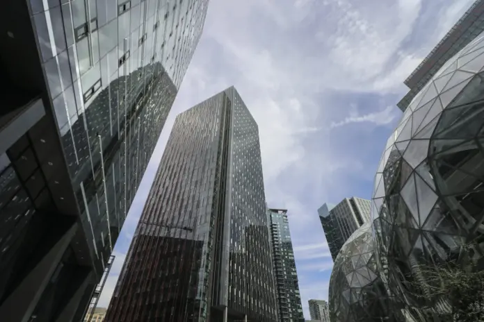 An Amazon price prediction that treats Anthropic's IPO paperwork as a larger version of June's markup is reading the wrong line. Reuters reported on 29 September that the lab's confidential prospectus commits Anthropic to spend $110 billion with Amazon between May 2026 and April 2036, "regardless of usage," inside a $518 billion plan with six partners, about 80% of it non-cancelable. Five days earlier Anthropic signed an $11.6 billion, seven-year CPU contract with Akamai, expandable by another $9 billion, so the same week produced a floor under AWS and a side door around it. Amazon (NASDAQ: AMZN) closed at $246.67 on 29 September, $6.87, or 2.7%, below the $253.54 close this column used on 14 September. From that print, FinanceFeeds' 12-month range is a $325 bull case, a $280 base case and a $210 bear case.
The split with the 15 September column is deliberate. That piece led with a $190.4 billion carrying value and a $340 / $190 range, because the mark was doing more work in GAAP earnings than AWS was. The prospectus does not erase the asset. It itemises a minimum bill, and Akamai shows that CPU demand is contestable. Spread over ten years, $110 billion is $11 billion a year, about 6.5% of the $169 billion AWS run rate. The Akamai commitment is about $1.7 billion a year, and it is CPU rather than Trainium. One figure is a floor. The other is a leak. The range $325 / $280 / $210 cuts the bull case for the leak and raises the bear case for the floor, off the $246.67 close and 2027 adjusted earnings of $10.48.
Key facts: Amazon (NASDAQ: AMZN)
AMZN closed at $246.67 on 29 September 2026, up 6.9% from the $230.82 close on 31 December 2025 and 13.2% below the $284.02 close on 3 August — <a href="https://api.nasdaq.com/api/quote/AMZN/historical?assetclass=stocks&fromdate=2025-09-30&todate=2026-09-30">Nasdaq historical prices, 29 Sep 2026</a>
Anthropic's prospectus commits $110 billion to Amazon from May 2026 to April 2036, payable regardless of usage, and at least $111.1 billion to Google — <a href="https://www.reuters.com/business/anthropics-518-billion-ai-buildout-hinges-largely-deals-that-cannot-be-canceled-2026-09-29/">Reuters, 29 Sep 2026</a>
The filing lays out at least $518 billion of spending with six partners over a decade, about 80% of it non-cancelable or due regardless of use — <a href="https://www.reuters.com/business/anthropics-518-billion-ai-buildout-hinges-largely-deals-that-cannot-be-canceled-2026-09-29/">Reuters, 29 Sep 2026</a>
Akamai signed an $11.6 billion, seven-year CPU commitment with Anthropic, expandable by $9 billion, plus a warrant for up to about 5% of Akamai — <a href="https://www.globenewswire.com/news-release/2026/09/24/3368729/0/en/akamai-announces-11-6-billion-multi-year-agreement-with-anthropic-to-support-growing-demand.html">Akamai, via GlobeNewswire, 24 Sep 2026</a>
Amazon and Google routed 47% of Anthropic's 2025 sales, about $2.16 billion of nearly $4.6 billion, and collected roughly $351 million in distribution fees — <a href="https://www.reuters.com/world/anthropic-ipo-prospectus-lays-bare-deep-dependence-big-tech-partners-2026-09-29/">Reuters, 29 Sep 2026</a>
59 analyst targets average $329.54, with a $230 low and a $405 high; adjusted EPS is $8.15 for 2026 and $10.48 for 2027 — <a href="https://stockanalysis.com/stocks/amzn/forecast/">S&P Global via stockanalysis.com, 28 Sep 2026</a>
The same series shows a 2026 free-cash-flow figure of -$34.18 billion, against 2026 revenue of $828.49 billion — <a href="https://stockanalysis.com/stocks/amzn/forecast/">S&P Global via stockanalysis.com, 28 Sep 2026</a>
What changed for Amazon stock in the last two weeks
The operating print has not changed since 30 July. Net sales were $200.6 billion, up 20%, and operating income was $27.5 billion, up 43%. AWS revenue was $42.2 billion, up 36.7%, a $169 billion annualized run rate, with backlog of $496 billion. Andy Jassy said 2026 cash capex would be about $220 billion, up from $200 billion on memory costs, and still short of 2026 and 2027 demand. <a href="https://financefeeds.com/amazon-raised-capex-to-220bn/">FinanceFeeds covered that raise</a> the next day. The papers since 15 September describe the customer, not a new quarter.
On 24 September Akamai said Anthropic had committed $11.6 billion over seven years for CPU workloads, expandable by $9 billion, plus a warrant for up to about 5% of Akamai at $111.33. About 2% vests now. Each further $3 billion vests about 1% more. Akamai will spend about $5.5 billion of capital and lift 2026 capex by about $1.7 billion, including for memory, with no 2026 revenue from the deal. The release is CPU. It does not cancel Trainium at AWS. It does contract a second supplier for work Amazon would rather keep.
On 29 September Reuters reported the prospectus: at least $518 billion with six partners over a decade, about 80% payable whether or not the capacity is used. The floors are $111.1 billion with Google, $110 billion with Amazon from May 2026 to April 2036, and $31.4 billion with Microsoft, together $252.5 billion. If spend falls short, the filing says Anthropic must pay Google the difference, and Reuters said the Amazon terms are similar. Do not stack the $110 billion on the $496 billion backlog. That book already held an Anthropic commitment Amazon had called more than $100 billion. The news is that the bill is now a named minimum. Amazon and Google also carried 47% of Anthropic's 2025 sales, about $2.16 billion. AMZN closed at $249.67 on 25 September and $246.67 on 29 September.
<blockquote>
We now believe we will spend approximately $220 billion in cash CapEx in 2026. The higher cost of memory pushing this number up from our prior estimate of about $200 billion. Even at that amount, we will still not have enough capacity to meet all the demand we have in 2026, and I believe this dynamic will also be true in 2027, too.
</blockquote>
Andy Jassy, Chief Executive Officer at Amazon, on the <a href="https://www.fool.com/earnings/call-transcripts/2026/08/07/amazon-amzn-q2-2026-earnings-call-transcript/">second-quarter earnings call</a>, 30 July 2026.
<strong>Quick take:</strong> The new information is a floor and a leak at the same time. $110 billion with Amazon is contracted. $11.6 billion of CPU is going to Akamai.
How Amazon, AWS and the Street responded
Amazon has not issued a new capex guide or a comment on the filing. Reuters said the company declined. The last operating statement is the 30 July call: capacity short through 2027, demand already visible for 2028, and both AI and custom chips above a $25 billion run rate. Jassy's line that AWS could become a trillion-dollar revenue business is a horizon. The 12-month question is whether $220 billion still holds at the third-quarter report, and whether the $110 billion minimum is earned inside AWS.
Since 15 September the Street has held targets, except at the floor. Alexander Haissl at Rothschild & Co Redburn maintained a Hold and a $230 target on 21 September, <a href="https://www.tipranks.com/news/blurbs/rothschild-co-redburn-remains-a-hold-on-amazon-amzn-blurbs-news">TipRanks reported</a>. That print is now the low on a 59-target S&P Global panel. On 3 September the prior column's panel had a $250 low and a $332.45 average across 42 targets. On 30 September stockanalysis.com showed an average of $329.54, a median of $330, a low of $230 and a high of $405, and a Strong Buy. The floor fell $20, to a Hold 6.8% under the close.
Jeffrey Wlodarczak at Pivotal Research kept a $333 Buy on 21 September. Ken Gawrelski at Wells Fargo kept a $338 Buy on 25 September, the session after Akamai. Mark Shmulik at Bernstein kept a $320 Buy on 28 September. Justin Post at Bank of America reiterated a $320 Buy on 14 September. None cut the target for the CPU contract or the take-or-pay language. A $320 to $338 cluster, with the shares near $247, still prices in June's AWS acceleration.
FinanceFeeds' $325 bull case sits in that cluster, $5 above Post and Shmulik and $4.54 under the $329.54 average. The Street's centre is this column's bull case, not its base. Haissl's $230 stays a Street target, $20 above the bear case here. S&P Global's adjusted EPS, on the same page as of 28 September, is $8.15 for 2026 and $10.48 for 2027, while 2026 net income is $140.10 billion. The net-income line still carries the Anthropic marks behind the $12.88 figure used on 15 September. This column's multiple uses $10.48. At the close, AMZN is 30.3 times 2026 adjusted EPS and 23.5 times 2027.
<blockquote>
Anthropic is advancing the AI revolution and we are thrilled they chose Akamai’s capabilities for building and operating AI infrastructure at scale.
</blockquote>
Dr. Tom Leighton, co-founder and Chief Executive Officer at Akamai, in the company's <a href="https://www.globenewswire.com/news-release/2026/09/24/3368729/0/en/akamai-announces-11-6-billion-multi-year-agreement-with-anthropic-to-support-growing-demand.html">24 September release</a>.
<strong>Quick take:</strong> The Street average of $329.54 is a bull case wearing a consensus label. The only target under the close is Redburn's $230 Hold.
Data, multiples and the scenario table
AMZN daily closes from 30 September 2025 to 29 September 2026, source Nasdaq historical prices. Dashed lines at $325, $280 and $210 are FinanceFeeds estimates, not Street targets.
At $246.67, AMZN is up 6.9% in 2026 from the $230.82 year-end close and up 12.3% from $219.57 on 30 September 2025. Using 10,786,313,572 shares outstanding as of 22 July, the market value is about $2.66 trillion. The path since mid-September is a drift, from $258.45 on 21 September to $246.67 on 29 September, not a gap on the Akamai release.
S&P Global's series, updated 28 September, puts adjusted EPS at $8.15 for 2026 and $10.48 for 2027, against 2026 net income of $140.10 billion and free cash flow of -$34.18 billion. Revenue is $828.49 billion this year and $948.22 billion next. The 15 September column's $12.88 figure was the mark-inflated line, beside 2027 EPS of $10.40. The multiples below use $10.48. The cash outflow is why the base case stays under the Street average.
Each target is one multiple times $10.48. The bull case is 31.0 times, or $324.88, set at $325, up 31.8%. That rolls today's 30.3 times 2026 adjusted multiple onto 2027, and it needs mid-30s AWS growth, capex held at $220 billion, and an IPO that does not puncture the stake. The base case is 26.7 times, or $279.82, set at $280, up 13.5%: a re-rating from 23.5 times, not a return to 30, because free cash flow stays negative and CPU demand has a second supplier. The bear case is 20.0 times, or $209.60, set at $210, down 14.9%. That is multiple compression if the IPO mark disappoints. It stays above the February close of $198.79 because a contractual floor makes a demand collapse the wrong story.
Scenario12-month targetVs $246.67Math on 2027 adjusted EPS ($10.48)Probability
Bull$325+31.8%31.0 x $10.48 = $324.8825%
Base$280+13.5%26.7 x $10.48 = $279.8250%
Bear$210-14.9%20.0 x $10.48 = $209.6025%
A 25/50/25 weighting gives $273.75, 11.0% above the close. Named bank targets stay outside this table. The $329.54 average is about 15% above the $280 base because free cash flow is forecast to stay negative.
Item15 September columnThis column
Reference price$253.54 (14 Sep close)$246.67 (29 Sep close)
Bull / base / bear$340 / $290 / $190$325 / $280 / $210
Earnings used2027 EPS $10.40, beside a 2026 figure of $12.882027 adjusted EPS $10.48; 2026 adjusted EPS $8.15
Lead factStake carried at $190.4 billion$110 billion take-or-pay, plus Akamai's $11.6 billion
Street low$250$230, Redburn Hold
<strong>Quick take:</strong> On adjusted 2027 earnings the shares already trade at 23.5 times. This Amazon price prediction's base case is a modest re-rating, not a new business.
The capital-structure tension behind the AWS backlog
Anthropic's minimum is an asset in Amazon's backlog and a liability on Anthropic's books. The lab lost more than $8 billion from operations in 2025 on under $4.6 billion of revenue. If usage falls short, the difference is still owed, which helps AWS only if Anthropic can pay. Cash and short-term investments at the end of 2025 were $20.28 billion, against a decade of minimums. The bridge is the IPO and money already invested by Amazon, Google and others.
The stake was carried at $190.4 billion on 30 June, per Amazon's <a href="https://www.sec.gov/Archives/edgar/data/1018724/000101872426000026/amzn-20260630.htm">Form 10-Q</a>. A cheaper listing would hit other income the way the $50.5 billion second-quarter gain lifted it. The filing already flags a lock-up, so a public price tests the mark without producing cash on day one. Long-term debt was $128.9 billion at 30 June, up from $65.6 billion at the end of 2025. The build is still $220 billion, funded with operating cash and debt, while a private valuation does heavy work in GAAP earnings.
Reuters quoted the prospectus on the overlap: Amazon, Google and Microsoft are each investor, customer, cloud provider, distributor and competitor, with incentives that "may not be fully aligned" with Anthropic's. Distribution fees of about $351 million in 2025 were the platforms' cut on $2.16 billion of marketplace sales. Akamai copied the equity-for-capacity shape, with a warrant for up to about 5%. A second supplier on that trade does not break AWS. It is another reason the circularity gets discounted when the cycle turns.
Power sits beside the contracts. The House passed the Ratepayer Protection Act 417-3 on 16 September, <a href="https://financefeeds.com/ratepayer-protection-act-data-center-grid-costs/">as FinanceFeeds reported</a>, so large data-center loads pay their own grid costs. Amazon's 20-year Vistra offtake, up to 1,200 megawatts from Comanche Peak from late 2027, is one way AWS has tried to lock power outside that fight, <a href="https://financefeeds.com/vistra-vst-has-4-gigawatts-of-nuclear-under-20-year-contract-to-amazon-amzn-and-meta-meta/">set out here on 8 September</a>. Reuters also reported on 15 September, and <a href="https://financefeeds.com/aws-cannot-restore-bahrain-uae-data-iran-strikes/">FinanceFeeds detailed</a>, that AWS could not restore some data in Bahrain and one UAE zone after Iranian strikes. A class action filed on 18 September, <a href="https://financefeeds.com/google-ai-slowdown-lawsuit-alphabet-antitrust/">covered separately</a>, alleges a coordinated slowdown of frontier models.
<strong>Quick take:</strong> A take-or-pay clause helps AWS only if the customer can pay. Anthropic's 2025 operating loss was larger than its revenue, and the cash pile was $20.28 billion.
What happens next, and what would move the range
Three paths follow from documents that now exist. Each one moves a different part of the range.
First, the third-quarter report, due in late October. Management's guide is sales of $197 billion to $202 billion and operating income of $22.5 billion to $26.5 billion. If AWS growth holds at or above the second quarter's 36.7% and backlog steps up from $496 billion, the $110 billion minimum is being absorbed into a larger book, and the base case moves toward $300. The mechanism is the multiple: 28.6 times $10.48 is about $300. If AWS growth slips under 30% while cash capex stays at $220 billion, the Akamai contract looks less like a side door and more like the start of a split, and the base case moves toward $250, about 23.9 times the same earnings figure.
Second, the listing. InvestmentNews, citing Reuters, said sources expect the offering after the November midterms, and Anthropic declined to comment. Reuters has also reported a sought valuation near $2 trillion. That would test a stake carried at $190.4 billion. It would not make the stake worth an unpublished percentage of $2 trillion. The 10-Q does not state a clean ownership share. A price that confirms the carrying value supports $325. A delay past year-end, or a value nearer the $965 billion May round, is the path to $210, through the income statement. <a href="https://financefeeds.com/anthropic-could-target-2-trillion-ipo-valuation-as-it-pitches-30-trillion-ai-market/">FinanceFeeds set out that $2 trillion pitch</a> in August.
Third, capex. Jassy has already added $20 billion to the 2026 figure on memory, and Akamai is adding about $1.7 billion of its own for the same parts. If Amazon's next update goes above $220 billion without a matching backlog increase, the -$34.18 billion free-cash-flow figure gets worse and 26.7 times is too rich. If the guide holds, the bull case stops at 31 times 2027 adjusted earnings. That is the top of this Amazon price prediction, not a return to $340.
FAQ
What is the Amazon price prediction for the next 12 months?
FinanceFeeds' Amazon price prediction from the 29 September 2026 close of $246.67 is a $280 base case, up 13.5%, a $325 bull case, up 31.8%, and a $210 bear case, down 14.9%, weighted 50/25/25. The probability-weighted value is $273.75. The call uses 2027 adjusted consensus earnings of $10.48 a share. It is a scenario range, not a recommendation to buy or sell the shares.
Why did the targets change from the 15 September call?
The 15 September column used $340, $290 and $190 off a $253.54 close. This update cuts the bull case by $15 and the base case by $10, and raises the bear case by $20. The prospectus disclosed a $110 billion Amazon minimum that the old bear case did not have in public form, while the Akamai CPU contract shows some demand can be placed outside AWS. The share price is also $6.87 lower than the old reference.
How much has Anthropic promised to spend with Amazon?
The confidential prospectus, as reported by Reuters on 29 September 2026, says Anthropic plans to spend $110 billion with Amazon between May 2026 and April 2036 regardless of usage. Similar terms apply to at least $111.1 billion owed to Google. With Microsoft's $31.4 billion, the three cloud minimums add to $252.5 billion. Spread evenly, the Amazon piece is about $11 billion a year, or roughly 6.5% of the current AWS run rate.
What do Wall Street analysts expect for AMZN?
S&P Global data on stockanalysis.com, checked on 30 September 2026, showed 59 analysts with a Strong Buy consensus and an average target of $329.54. The median was $330, the low $230 and the high $405. Rothschild & Co Redburn's Alexander Haissl sits at the low, with a Hold and a $230 target as of 21 September. Those are Street targets. They are separate from the FinanceFeeds bull, base and bear cases above.
Is Amazon's free cash flow negative?
Trailing twelve-month free cash flow was an outflow of $7.6 billion at the end of the second quarter of 2026. The S&P Global series on stockanalysis.com shows a 2026 free-cash-flow figure of -$34.18 billion. Cash capex for 2026 is guided to about $220 billion, up from about $200 billion, on higher memory costs and more capacity. That gap is why the $280 base case stays below the $329.54 Street average even after a 37% AWS quarter.
<em>Disclaimer: This article is analysis, not investment advice. Price scenarios are illustrative, based on public filings, company statements and market data available on 30 September 2026, and are not a recommendation to buy or sell any security. Equity investments can lose money, including the entire amount invested.</em>