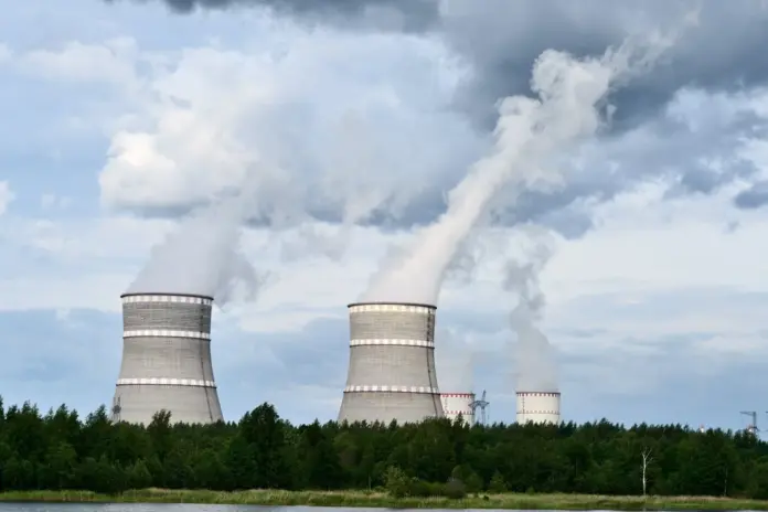 Almost every summary of X-Energy you will read says the company reached the public market through the Ares Acquisition Corporation II blank-cheque vehicle. It did not. The SEC file for CIK 0002088896 contains no SPAC merger at all: a draft registration statement in November 2025, an S-1 in March 2026, four amendments, an effectiveness order on 23 April 2026, and a Rule 424(b)(4) prospectus pricing 44,254,659 Class A shares at <strong>$23.00</strong>. X-Energy, Inc. (Nasdaq: XE) began trading on <strong>24 April 2026</strong> and closed the offering on 27 April. That distinction is not pedantry. A de-SPAC arrives with warrants, redemptions and a scattered register; a conventional IPO arrives with a 180-day underwriter lock-up and a float of roughly 12% of the share count. The second of those is, in our reading, the single most important fact about where XE trades between now and spring 2027 — and it is the one the "de-SPAC" shorthand hides.
Here is the insight that follows from it. XE closed at <strong>$17.26</strong> on 9 September 2026, down 9.87% on the day and 53% below the $37.10 intraday high set on 28 April. The instinct is to read that as a company-specific verdict on a first-of-a-kind reactor developer. The peer tape says otherwise. Measured from their own 52-week highs, Oklo is down 78%, NuScale down 81%, Nano Nuclear down 70% and Centrus down 61%. X-Energy's 53% is the <em>shallowest</em> drawdown in the pure-play small modular reactor complex, not the deepest. What was repriced was an entire category. What is left to explain is the 9 September gap specifically — because on that day Oklo fell 1.71%, NuScale 3.31% and Centrus 2.18%, while XE fell three to six times harder, and X-Energy filed no 8-K. That asymmetry, and the lock-up clause that sits behind it, is what this piece is about.
X-Energy (XE) daily closes since the 24 April 2026 Nasdaq debut, with the scenario levels used in this article. Source: Nasdaq daily closes; scenario levels FinanceFeeds.
Key facts: X-Energy (XE) at a glance
Share price <strong>$17.26</strong>, down $1.89 (-9.87%) on volume of 9,803,571 — <a href="https://api.nasdaq.com/api/quote/XE/info?assetclass=stocks">Nasdaq, 9 September 2026 close</a>
Market capitalisation <strong>$7.014bn</strong> across 287.4m Class A and 118.9m Class B shares — Nasdaq and <a href="https://www.sec.gov/Archives/edgar/data/2088896/000119312526347752/xe-20260630.htm">Form 10-Q, 13 August 2026</a>
IPO priced at <strong>$23.00</strong>; first trade 24 April 2026; approximately <strong>$1.1bn</strong> net proceeds — <a href="https://www.sec.gov/Archives/edgar/data/2088896/000110465926049515/tm2527015-22_424b4.htm">Form 424(b)(4), 27 April 2026</a>
Q2 2026 revenues and grant income <strong>$54.6m</strong>, up 154% year on year; total operating expenses $164.6m — <a href="https://www.sec.gov/Archives/edgar/data/2088896/000119312526347740/xe-ex99_1.htm">Q2 results, 13 August 2026</a>
Q2 net loss <strong>$105.3m</strong>; net cash used in operating activities $97.3m, up 387% year on year — Q2 results, 13 August 2026
Cash, short-term and long-term investments of <strong>$1.90bn</strong> against total liabilities of just $159.6m at 30 June 2026 — Form 10-Q, 13 August 2026
The US Government accounted for <strong>90.9%</strong> of revenue and grant income in the first half of 2026; Dow accounted for 4.4% — Form 10-Q, 13 August 2026
What X-Energy actually sells, and why 91% of its revenue is a reimbursement
X-Energy designs the Xe-100, a high-temperature gas-cooled reactor sold in a standard four-unit configuration, and manufactures the TRISO-X fuel it runs on. The fuel is the more unusual half of the business. TRISO particles are uranium kernels individually wrapped in silicon carbide and pyrolytic carbon, then embedded in a graphite matrix and formed into pebbles. Each particle is effectively its own containment vessel, which is why the design can claim passive safety margins that a conventional plant achieves with a 16-kilometre emergency planning zone and the Xe-100 expects to achieve with 400 metres.
The commercial pipeline is real and named. Dow, Amazon and Centrica together represent more than 11 gigawatts electric and a 144-reactor pipeline across the United States and the United Kingdom, assuming every contingent right is exercised. Advanced work is under way on two of them: four reactors at Dow's Seadrift site in Texas, and an Amazon-backed project with Energy Northwest in central Washington sized at 320 MWe with an upsize path to 960 MWe. Amazon took an equity stake in 2024 and has announced options for more than 5 GWe of Xe-100 capacity by 2039.
Now the part that governs the multiple. Of the $98.0m of revenue and grant income X-Energy booked in the first half of 2026, 90.9% came from the US Government. That is not product revenue. It is the government's half of the Department of Energy's Advanced Reactor Demonstration Program, a <strong>50/50 cost share on $2.4bn of eligible costs</strong>, of which at least $1.1bn has been allocated to X-Energy's award. When the company reports that revenue rose 154% year on year, the driver disclosed in the filing is a $31.9m increase in ARDP receipts caused by higher spending on materials, subcontractors and payroll. In other words, revenue grew because costs grew. Strip the cost-share out and the commercial business is a rounding error: Dow, the flagship customer, was 4.4% of the top line.
This is the disciplined way to read a pre-commercial reactor developer, and it is why we treat the headline growth rate with caution. X-Energy expects its first commercial reactor delivery in the early 2030s. Everything between now and then is spending, licensing and construction — funded, for the moment, extremely well.
How the balance sheet and the rest of the complex actually look
The funding position is the strongest part of the story and deserves to be stated precisely, because runway estimates built off a stale balance sheet have burned people in this sector before. At 30 June 2026 X-Energy held $1,145.4m of cash and equivalents, $489.8m of short-term investments and $264.6m of long-term investments — <strong>$1.90bn of liquidity</strong> — against total liabilities of $159.6m and no debt. The $274.2m warrant liability that sat on the December 2025 balance sheet has gone to zero. We then checked every filing made after the 10-Q: the only submissions between 13 August and 10 September 2026 are Schedule 13G passive ownership reports. There has been no follow-on, no ATM, no convertible and no new DOE tranche disclosed since the quarter closed. The $1.90bn is the current picture.
Against a Q2 operating cash burn of $97.3m, that is roughly five years of runway on a static reading. The static reading is wrong. Operating burn rose 387% year on year in the quarter, investing outflows ran to $239.6m in the half, and the ARDP budget period — recently extended — now runs only through <strong>March 2027</strong>. The honest framing is that X-Energy is funded through the licensing and early-construction phase with real margin, and will need either a successor ARDP allocation from the $3.1bn Congress appropriated to the programme or commercial milestone payments before construction spending peaks. Notably, neither the 10-Q nor the prospectus contains any going-concern or substantial-doubt language. We searched for both. There are zero occurrences.
Set that against the group. At $17.26 the market pays $7.014bn for X-Energy. Oklo, with essentially no revenue, is worth $7.919bn. <a href="https://financefeeds.com/nuscale-smr-stock-prediction-18-bull-4-50-bear/">NuScale</a> is worth $4.645bn and Nano Nuclear $0.976bn. Deduct X-Energy's $1.90bn of net cash and the enterprise value is roughly <strong>$5.11bn</strong>, or about 26 times annualised first-half revenue — revenue that is, as established, mostly reimbursed development cost. That is not cheap. It is, however, the only balance sheet in the pure-play group that can absorb a two-year licensing delay without a dilutive raise, which is a genuinely different risk profile from <a href="https://financefeeds.com/fermi-frmi-stock-prediction-12-bull-2-50-bear/">Fermi</a> or the smaller developers.
The lock-up clause that explains 9 September
Return to the anomaly. XE fell 9.87% on 9 September while its closest comparables fell between 1.71% and 6.10%, and the company disclosed nothing. When a stock gaps without news, the usual culprit is supply, and the prospectus tells you exactly where the supply is.
The lock-up runs 180 days from the 23 April 2026 prospectus date, which lands on or about <strong>20 October 2026</strong>. But the agreement contains an early-termination mechanic that is easy to miss. In the underwriters' own words, if "(1) at least 120 days have elapsed since the date of this prospectus and (2) such lock-up period is scheduled to end during or within five trading days prior to a broadly applicable period during which trading in our securities would not be permitted under our insider trading policy, or a blackout period, such lock-up period will end ten trading days prior to the commencement of such blackout period."
The 120-day condition was satisfied on approximately 21 August 2026. Both conditions are therefore live right now. If X-Energy's third-quarter blackout begins in the days after the 30 September quarter end — which is the ordinary corporate practice — then the October expiry would fall inside or adjacent to it, and the lock-up would instead terminate ten trading days before the blackout starts. That is September, not October. J.P. Morgan Securities LLC can also release holders early at its sole discretion, with pro rata release rights for certain others.
The scale of what is released is the point. The IPO sold 44,254,659 shares, with an option over a further 6,638,198. Total shares outstanding are 406.3m. Continuing Equity Owners alone hold 118,907,374 common units exchangeable into Class A stock. So roughly 87% of the register has been locked, sitting against a free float of around 12%. We would not present this as confirmed causation — the precise blackout dates are not public, and we could not verify them. But it is a dated, filing-sourced mechanism that fits the tape better than any news-driven explanation, and it is exactly the dynamic that played out in <a href="https://financefeeds.com/spacex-spcx-lockup-september-9-319-million-shares/">the SpaceX unlock earlier this month</a>. Positioning ahead of a known supply event does not require an 8-K.
Licensing: the one catalyst that is not about supply
The offsetting force is regulatory, and it is closer than most people realise. Long Mott Energy, a wholly owned Dow subsidiary, filed the construction permit application for the four-unit Seadrift project in March 2025. The NRC docketed it in May 2025 on an 18-month review — described in the prospectus as one of the shortest construction permit timelines ever granted — with review completion expected in <strong>late 2026</strong>. The NRC has already completed its Environmental Assessment ahead of schedule and issued a Finding of No Significant Impact.
If that permit is granted, it would be the first NRC construction permit for a commercial high-temperature gas-cooled reactor in the United States. For a company whose entire equity value is an option on regulatory execution, that is the event that converts a design into a buildable asset. The supporting chain has also been quietly de-risked through 2026: long-term HALEU enrichment agreements with Centrus Energy and General Matter, an agreement to double SGL Carbon's European nuclear-grade graphite capacity by 2030 for up to $8m in milestone payments, an $11m Tennessee grant, a 70-acre land purchase taking the Oak Ridge campus to roughly 180 acres under the NRC Part 70 licence, and vertical construction of the TX-1 fuel facility reported on schedule.
Chief executive J. Clay Sell framed the fuel and materials agreements as the substantive de-risking step in the company's second-quarter statement: "Our HALEU enrichment service agreements meaningfully de-risk a substantial portion of the deployment of our reactors, and the agreement with SGL secures our access to critical graphite components, enabling our strategy to build reactors at scale." He added: "Overall, we believe this momentum only reinforces our ability to deliver for our customers and continues to build a moat between us and our competitors."
The arithmetic behind $31, $20 and $11
Our scenario horizon is <strong>31 March 2027</strong>, chosen because three dated catalysts land inside it: the lock-up expiry, the Seadrift permit decision, and the end of the extended ARDP budget period.
ScenarioLevelvs $17.26 spotImplied EV/annualised revenueWhat has to happen
<strong>Bull</strong>$31.00+80%~55xSeadrift construction permit granted; TX-1 completes on schedule; a further ARDP allocation from the $3.1bn appropriation; the unlock is absorbed without a break of the July low
<strong>Base</strong>$20.00+16%~32xThe August congestion band holds; the permit slips a quarter; supply clears in an orderly way and the stock stays below its $23.00 IPO price
<strong>Bear</strong>$11.00-36%~13xA disorderly unlock into a complex already down 50-80%; the permit slips beyond mid-2027; the ARDP budget period lapses in March 2027 without a clean successor
The bull case is deliberately set below the $35.98 peak close and near the debut-week trading band rather than at a new high. At $31 the enterprise value is about $10.7bn on roughly 55 times annualised revenue, which is what this group commands when sentiment is running. We are also, deliberately, below the sell side: the consensus one-year target carried by Nasdaq is <strong>$38.00</strong>, implying 120% upside. We think that target underweights the supply event, because a price objective set on fundamentals does not model 355m shares becoming saleable into a 50m-share float.
The bear case sits 17% below the $13.29 low of 16 July. Even there, the enterprise value is about $2.57bn on roughly 13 times revenue, so $11 is not a distress price — it is what a still-expensive developer looks like after a forced-supply reset. Net cash alone is about $4.68 per share, which is the floor beneath the floor and the reason we did not go lower.
<strong>Invalidation levels.</strong> The bull case is dead on a weekly close below <strong>$13.29</strong>, the July low; that would confirm the unlock overwhelmed the licensing catalyst. The bear case is dead on a weekly close above <strong>$23.00</strong>, the IPO price; reclaiming the level at which institutions bought would signal the supply has been absorbed and the permit is being priced in.
What happens next: three predictions
<strong>One: the supply event resolves before the permit decision, and sets the range.</strong> Whether the lock-up lifts in late September under the early-termination clause or on 20 October as scheduled, it precedes the Seadrift review completion. Expect elevated volume and a retest of the $13.29-$15.00 zone into the unlock. How that test holds, rather than the permit itself, is what sets the trading range into 2027.
<strong>Two: the ARDP renewal becomes the disclosure that matters most, and few are watching it.</strong> The budget period ends in March 2027 and Congress has appropriated $3.1bn to the programme. Because roughly 91% of reported revenue is the government's cost-share, the size of X-Energy's next allocation mechanically determines the reported revenue line. A smaller-than-expected allocation would show up as a revenue decline that has nothing to do with commercial demand — and would very likely be misread as one.
<strong>Three: capital discipline separates this name from the group within twelve months.</strong> With $1.90bn and no debt, X-Energy does not need to raise into weakness, which is not true of most of its peers. If the sector stays de-rated through 2027, the differentiator will not be reactor design but who is forced to issue equity at the lows. On that measure X-Energy is the best-positioned pure-play in the complex, which is a materially different claim from saying the shares are cheap. They are not. For investors who want nuclear exposure with revenue and dividends today rather than an option on 2030, the operating utilities — <a href="https://financefeeds.com/constellation-energy-ceg-stock-prediction-bull-bear-case/">Constellation</a> and <a href="https://financefeeds.com/vistra-vst-stock-prediction-225-bull-95-bear-sp-500/">Vistra</a> — and the fuel-cycle names such as <a href="https://financefeeds.com/cameco-ccj-stock-prediction-bull-bear-case/">Cameco</a> remain the lower-variance route.
Frequently asked questions
Is X-Energy a de-SPAC?
No. Despite the widespread claim that X-Energy merged with Ares Acquisition Corporation II, the SEC filing history for CIK 0002088896 shows a conventional initial public offering: a confidential draft registration in November 2025, an S-1 in March 2026, effectiveness on 23 April 2026 and a 424(b)(4) prospectus pricing shares at $23.00. The term "Ares Acquisition" does not appear anywhere in the company's Form 10-Q.
Why did X-Energy stock fall 53% from its high?
Most of the decline is sector-wide de-rating rather than company-specific. Oklo, NuScale, Nano Nuclear and Centrus are all down between 61% and 81% from their own 52-week highs over a comparable period, so X-Energy's fall is the shallowest in the group. The stock also debuted at a large premium, closing its first day at $29.20 against a $23.00 IPO price, so part of the fall is simply that premium unwinding.
When does the X-Energy IPO lock-up expire?
The standard expiry is 180 days from the 23 April 2026 prospectus date, on or about 20 October 2026. However, the lock-up agreement allows earlier termination: once 120 days have elapsed — satisfied around 21 August 2026 — and if expiry would fall during or within five trading days of a corporate blackout period, the lock-up instead ends ten trading days before that blackout begins. J.P. Morgan Securities LLC may also release holders early at its discretion.
Is X-Energy profitable?
No. X-Energy reported a net loss of $105.3m in the second quarter of 2026 and $271.6m in the first half, on revenues and grant income of $98.0m. Total operating expenses of $274.2m in the half ran well ahead of the top line. The company expects its first commercial reactor delivery in the early 2030s, so meaningful product revenue is years away.
How much cash does X-Energy have?
At 30 June 2026 the company held $1,145.4m in cash and equivalents plus $489.8m of short-term and $264.6m of long-term investments — about $1.90bn — against $159.6m of total liabilities and no debt. No capital raise or new funding tranche has been disclosed in any filing since the 10-Q was filed on 13 August 2026.
What is a realistic X-Energy stock prediction for 2027?
Our scenarios to 31 March 2027 are $31 bull, $20 base and $11 bear against a $17.26 spot price. The bull case requires the NRC construction permit for the Dow Seadrift project plus an orderly lock-up unlock; the bear case assumes a disorderly unlock and a licensing slip. The Nasdaq consensus one-year target is higher at $38.00, which we believe underweights the share-supply event.
<em>This article is analysis, not investment advice. Prices and scenario levels are as of the 9 September 2026 close.</em>
