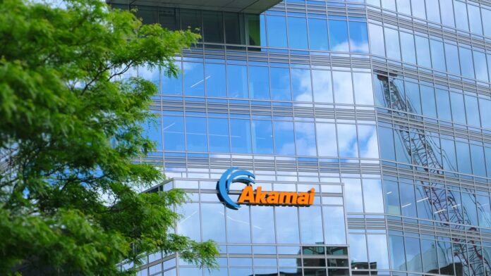 <strong>Akamai Technologies</strong> (AKAM) is not a name that usually comes up when people talk about artificial intelligence. That changed on Thursday, <strong>September 24, 2026</strong>, when the cloud and cybersecurity company confirmed a seven-year, <strong>$11.6 billion</strong> cloud services deal with Anthropic.
The contract is the biggest in Akamai’s history, and it could grow to <strong>about $20 billion</strong> if Anthropic buys more services over time. AKAM shares jumped as much as <strong>16.4%</strong> during Friday trading on September 25, 2026, before closing <strong>near $115</strong>. Wall Street analysts raised their price targets within hours, including Morgan Stanley, Guggenheim, JPMorgan, and Oppenheimer.
Akamai has slowly moved from its old business, which is helping websites load faster, and cybersecurity, into renting out cloud computing power to other companies. This Anthropic deal proves that diversification is working. But the deal also comes with heavy spending and some stock dilution that shareholders should understand before buying.
Inside Akamai’s $11.6 billion Anthropic contract
Akamai will supply dedicated cloud capacity to run Anthropic’s AI workloads for <strong>seven years</strong>, according to <a href="https://www.ir.akamai.com/news-releases/news-release-details/akamai-announces-116-billion-multi-year-agreement-anthropic">Akamai</a>‘s announcement. The deal focuses on central processing units (CPUs), which are the general-purpose chips that handle everyday computing tasks. That is different from most other big AI deals, which center on graphics processing units (GPUs) sold by Nvidia (NVDA). GPUs train large AI models, while CPUs handle the coordination work that AI agents do when they perform tasks like booking travel or answering support questions.
The deal can grow by <strong>another $9 billion</strong> if Anthropic keeps buying more Akamai services, taking the total to <strong>about $20 billion</strong>. As part of the arrangement, Akamai gave Anthropic a financial contract that lets Anthropic buy <strong>up to 5%</strong> of Akamai’s stock at <strong>$111.33 per share</strong>, <a href="https://techcrunch.com/2026/09/25/anthropic-to-pay-akamai-11-6-billion-over-seven-years-in-cloud-deal/">TechCrunch</a> reported. About 2% of that stake becomes available right away, and each extra $3 billion Anthropic spends unlocks another 1%.
“Anthropic is advancing the AI revolution and we are thrilled they chose Akamai’s capabilities for building and operating AI infrastructure at scale,” Akamai co-founder and CEO <a href="https://www.akamai.com/company/leadership/board-of-directors/tom-leighton">Dr. Tom Leighton</a> said in the announcement. Leighton has led Akamai since 2013.
Akamai Technologies signed the largest contract in company history with Anthropic on September 24, 2026, marking its clearest step yet into AI cloud infrastructure.<a href="https://www.gettyimages.com/detail/2159351667">Veronique D / Getty Images</a>
How Akamai makes money and where this deal fits in
Akamai started in 1998 with a product that helps websites load faster by delivering content from a server close to you rather than a distant one. Over the years, it added cybersecurity tools that block bots and online attacks.
In 2022, it bought <strong>Linode</strong> and began renting out computing power to other companies. This part of the business is called cloud infrastructure services (CIS). Security and cloud now drive most of Akamai’s growth, while the old business has been shrinking.
<strong>More AI Stocks:</strong>
<strong><a href="https://www.thestreet.com/investing/stocks/openai-cfo-offers-calming-message-amid-ai-slowdown-fears">OpenAI CFO offers calming message amid AI slowdown fears</a></strong>
<strong><a href="https://www.thestreet.com/investing/stocks/senator-blumenthal-doomsday-ai-warning-kill-switch-act">U.S. senator sends 7-word doomsday AI warning amid industry panic</a></strong>
<strong><a href="https://www.thestreet.com/investing/stocks/bank-of-america-says-ai-data-center-demand-strong">BofA cuts to the chase on AI data center demand</a></strong>
In the first quarter of 2026, Akamai reported revenue of <strong>$1.074 billion</strong>, <strong>up 6%</strong> year over year, according to its <a href="https://www.sec.gov/Archives/edgar/data/0001086222/000108622226000054/exhibit991-q12026.htm">SEC</a> release. Security revenue <strong>rose 11%</strong> to <strong>$590 million</strong>, and cloud infrastructure services revenue <strong>jumped 40%</strong> during Q1, though CIS was still a small part of total sales. The Anthropic deal changes that.
Akamai expects the yearly cloud revenue from this contract alone to reach <strong>about $1.7 billion</strong> by the end of 2028, <a href="https://www.cnbc.com/2026/09/25/shares-of-akamai-surge-after-deal-with-anthropic-what-wall-street-is-saying.html">CNBC</a> reported, which would reshape the company’s growth outlook.
Wall Street repositions on Akamai after its biggest contract yet
Analysts at major firms raised price targets and revenue forecasts within hours of the announcement. Morgan Stanley kept its <strong>Overweight rating</strong> and <strong>$165 price target</strong>, and now expects <a href="https://www.thestreet.com/investing/stocks/morgan-stanley-akamai-akam-stock-price-target-reset">Akamai’s revenue growth</a> in 2027 to jump from 12.5% to <strong>about 16%</strong>. That is a big move from the 5% growth Akamai reported in 2025.
<strong><a href="https://www.thestreet.com/investing/stocks/mike-khouw-says-buy-vertiv-despite-making-huge-gains-already">Related: Veteran analyst says buy Vertiv despite huge gains already</a></strong>
Guggenheim raised its price target on AKAM to <strong>$225</strong> from $190 with a <strong>Buy rating</strong>. JPMorgan lifted its target to <strong>$167</strong> from $158, and UBS moved to <strong>$148</strong> from $143 while staying <strong>Neutral</strong>. Piper Sandler analyst <a href="https://www.tipranks.com/experts/analysts/james-fish">James Fish</a> kept an <strong>Overweight rating</strong> and raised his target to <strong>$158</strong> from $125, saying the deal turns Akamai “from a value asset to a hypergrowth” asset, <a href="https://stocktwits.com/news-articles/markets/equity/akamai-anthropic-deal-s-magnitude-is-impressive-says-piper-sandler-sees-it-shift-from-being-a-value-asset-to-a-hypergrowth-one/cZMO73pRBaD">Stocktwits</a> reported.
Oppenheimer analysts, who kept an <strong>Outperform rating</strong> and <strong>$180 target</strong>, wrote that the deal “shows that Akamai’s distributed cloud can win frontier AI workloads.” They estimate that Anthropic’s $1.7 billion in yearly revenue means <strong>about 77 megawatts</strong> of new cloud capacity for Akamai, and they expect similar deals from other AI companies could follow.
The trade-offs shareholders should weigh before buying AKAM
Akamai plans to spend <strong>about $5.5 billion</strong> to build the capacity for Anthropic over the seven-year term, <a href="https://finance.yahoo.com/technology/ai/articles/akamai-lands-11-6-billion-203833354.html">Yahoo Finance</a> reported. The company is raising its 2026 capital spending by <strong>about $1.7 billion</strong> to secure memory chips and supply chain parts, and says the deal will not add to revenue this fiscal year.
The warrant given to Anthropic could also dilute existing shareholders by up to 5% over time. That means each share would represent a smaller piece of the company as Anthropic buys more stock. New investors have to decide whether the recurring cloud revenue starting in late 2027 will offset the near-term spending and dilution.
Concentration risk is another thing to watch. When one customer makes up a big share of revenue, that customer’s problems affect the whole company. Some Wall Street analysts have already mentioned concerns about Akamai relying too much on Anthropic, <a href="https://www.investopedia.com/market-update-akamai-stock-soars-on-11-billion-deal-with-anthropic-12140070">Investopedia</a> reported. Investors interested in the AI infrastructure market can consider going for AKAM, but should evaluate the risks involved before buying in.
<strong><a href="https://www.thestreet.com/investing/stocks/truist-cuts-broadcom-avgo-stock-target-on-rattling-q4-outlook">Related: Truist cuts Broadcom stock target on rattling Q4 outlook</a></strong>