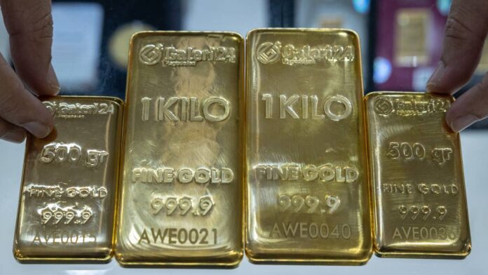 Gold’s 2026 story was mostly supposed to be how high the safe-haven trade could potentially run.For context, the shiny yellow metal soared roughly 63% in 2025, according to <a href="https://www.lbma.org.uk/articles/lbma-precious-metals-market-report-q4-and-full-year-2025">LBMA benchmark data</a>, the strongest annual gain in more than four decades. Lately, though, the bull case has been tested, and then some <a href="https://uk.finance.yahoo.com/quote/GC%3DF/">Yahoo Finance’s quotes</a> show August gold futures trading around $3,975.40 per ounce, down 10.6% over the past month and 7.5% since the start of the year. Though the long-term bull case remains in place, the near-term setup has become much less comfortable.In a note shared with me, BofA sees a market that’s caught between strong structural support and increasingly fragile technical signals. Positioning remains crowded, key moving averages have weakened, and the latest rebound hasn’t settled where buyers are truly back in control. At the same time, gold is still holding at levels that preserve the broader uptrend.
Gold prices face renewed uncertainty as BofA sees a longer correction ahead<a href="https://www.gettyimages.com/detail/news-photo/gold-bars-are-displayed-at-galeri-24-a-state-owned-gold-news-photo/2258027793">KRISTIANTO PURNOMO / AFP via Getty Images</a>
<strong>Gold’s long-term bull market is intact, but 2026 may be a lost year </strong>Bank of America analysts believe that the breathtaking rally into January 2026 was so stretched that the subsequent correction will take longer and may entail further downside before a durable bottom forms.<strong>More Bank of America:</strong><a href="https://www.thestreet.com/economy/bank-of-america-warns-america-now-has-2-economies"><strong>Bank of America warns America now has 2 economies</strong></a><a href="https://www.thestreet.com/investing/stocks/bank-of-america-warns-of-tougher-stock-market-in-near-future"><strong>Bank of America answers a tough stock market question</strong></a><a href="https://www.thestreet.com/investing/bank-of-america-gives-stock-market-investors-a-summer-reality-check"><strong>Bank of America gives stock market investors a summer reality check</strong></a>Essentially, the bank’s analysts point to a conflict between gold’s long-term <a href="https://www.thestreet.com/dictionary/f/fundamentals">fundamentals</a> and its near-term technical condition. Though the safe-haven metal remains in a secular uptrend, the charts resemble the aftermath of prior speculative peaks. For perspective, the tremendous rally from October 2023 to January 2026 lasted 121 weeks, while the correction lasted just 24 weeks.The imbalance makes it premature for the analysts to say that the selloff finished simply because bullion has stabilized near $4,000.Consequently, BofA believes gold might spend the bulk of the second half of 2026 consolidating, bouncing, and potentially falling again before potentially picking up the pace in 2027 or 2028.<strong>Several warning signals suggest the bottom is not secure </strong>BofA analysts further argue that after falling almost 30% from its January peak, it reached its major Fibonacci retracement near $4,149 and attracted buyers around $4,000. For perspective, Fibonacci retracements are technical levels derived from common ratios, including 38.2%, 50%, and 61.8%, that are used to estimate where an asset could find support following a momentous rally.However, BofA argues that markets don’t correct through price alone, as they can also move sideways for months while momentum, positioning, and investor expectations normalize.What’s crucial to consider is the time imbalance. Considering gold's rally lasted 121 weeks, and the correction was just 24 weeks old, a <a href="https://www.thestreet.com/dictionary/p/pullback">pullback</a> lasting roughly 38.2% of the previous move higher would extend to nearly 46 weeks. That points to the bullion remaining mostly unsettled into late 2026.That said, BofA’s technical roadmap paints a relatively volatile path ahead instead of a clean rebound:<strong>A rally may come first:</strong> Gold could rebound toward <strong>$</strong>4,325 to $4,500, but a move above $4,300 might not end the correction, forming a potential lower high instead before selling resumes.<strong>Key downside levels remain:</strong> BofA sees potential support around the 50% <a href="https://www.investopedia.com/terms/f/fibonacciretracement.asp">Fibonacci retracement</a> at $3,703, with another long-term technical measure pointing to roughly $3,605.<strong>Momentum still looks fragile:</strong> Gold triggered a <a href="https://www.investopedia.com/terms/d/deathcross.asp">death cross </a>on June 26, which basically means that its 50-day <a href="https://www.thestreet.com/dictionary/m/moving-average">moving average</a> dropped behind its 200-day average, signalling weaker momentum. Historically, gold was lower 70% of the time, 40 trading days after comparable signals.<strong>One bullish counter-signal remains:</strong> Gold’s <a href="https://www.investopedia.com/terms/r/rsi.asp">RSI</a>, measuring the speed and strength of price moves, reached an extremely overbought 90. However, a <a href="https://www.scribd.com/doc/35718031/Td-Sequential">TD Sequential “red 13”</a>, used to flag possible trend exhaustion, suggests selling pressure may be fading while gold holds above $3,827.
Sources: Investopedia, Scribd.
<strong>BofA’s strategy is to buy gradually at lower levels</strong>BofA is advising investors to avoid chasing gold near $4,000 while the correction is still developing.The bank suggests taking a small position below $4,000, adding more around $3,700 to $3,600, while building a fuller allocation in the $3,450 to $3,250 range. That approach underscores BofA’s broader view that the risk-reward improves meaningfully at lower prices.Moreover, the bank also prefers gold itself over silver and gold-mining ETFs such as <a href="https://www.thestreet.com/quote/GDX">GDX</a> and <a href="https://www.thestreet.com/quote/GDXJ">GDXJ</a>. Physical gold offers direct exposure to bullion prices, while miners are up against a myriad of added risks linked to costs, operations and stock-market <a href="https://www.thestreet.com/dictionary/v/volatility">volatility</a>.Within the mining space, BofA feels larger producers are far better positioned than junior miners. Newmont (<a href="https://www.thestreet.com/quote/NEM">NEM</a>) is singled out as perhaps the strongest relative option among major miners, with the stock holding up a lot better than the broader GDX ETF.Nevertheless, Newmont remains in a correction, with possible downside toward $86 to $82 unless a durable bottom forms.Over the past month, the stock has shed 17% of its value and over 9.5% year-to-date, according to data from<a href="https://seekingalpha.com/symbol/NEM/momentum/performance"> Seeking Alpha</a>.However, after the sell-off, the stock is now trading attractively, at around <a href="https://seekingalpha.com/symbol/NEM/valuation/metrics">9.5-times forward earnings (non-GAAP)</a>.<strong><a href="https://www.thestreet.com/investing/microsoft-ceo-adds-fuel-to-palantir-ceos-ai-warning">Related: Microsoft CEO adds fuel to Palantir CEO’s AI warning</a></strong>