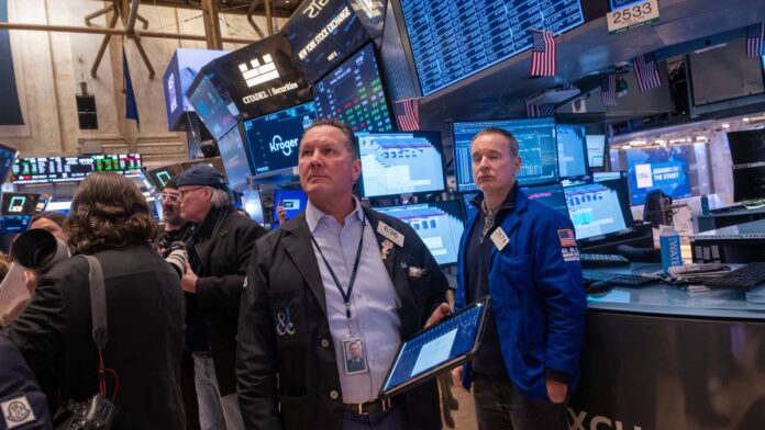 In the span of a few days in early June, <a href="https://www.thestreet.com/tag/artificial-intelligence">AI</a> and chip stocks lost $1.3 trillion in market value. U.S. semiconductor names got hit hard. Investors who had been riding the AI wave suddenly started asking whether the trade had run too far ahead of reality.<a href="https://www.thestreet.com/personalities/nvidia-founder-huang-net-worth">Jensen Huang</a> was in Seoul on June 8 for a series of business meetings. Instead of staying quiet, he walked out and told investors what he thought they should do with a down market: buy it.<strong>What Jensen Huang said about the AI boom and the stock market sell-off</strong>"We're at the beginning of it, and whatever happened to the stock market, you should be very happy because now you can buy at a discount," Huang told reporters in Seoul, according to <a href="https://www.bloomberg.com/news/articles/2026-06-08/nvidia-ceo-shrugs-off-tech-stock-rout-with-ai-just-beginning">Bloomberg</a>. "Everybody should be very excited."The trip itself was part of the story. On the same day, <a href="https://www.thestreet.com/quote/NVDA">Nvidia</a> and SK Hynix, one of the world's largest memory chip manufacturers and a key supplier to U.S. AI data centers, announced a multi-year partnership to design future generations of AI memory chips. <strong>More Nvidia:</strong><a href="https://www.thestreet.com/investing/bank-of-america-sees-vera-cpu-nvidia-20-billion-business"><strong>Bank of America sees Nvidia’s next $20 billion business</strong></a><a href="https://www.thestreet.com/investing/stocks/morgan-stanley-says-nvidia-stock-remains-top-pick-despite-headwind"><strong>Morgan Stanley says Nvidia stock remains top pick despite headwind</strong></a><a href="https://www.thestreet.com/investing/stocks/citi-sends-strong-signal-to-nvidia-investors-amid-rumours"><strong>Citi sends strong signal to Nvidia investors amid rumors</strong></a>That deal signals that Nvidia is still building, still signing long-term agreements, and still betting on the infrastructure buildout that Huang has been describing for the past two years. You don't sign a multi-year chip partnership on the day you think the cycle is turning.Huang also called AI infrastructure "a foregone conclusion," comparing it to the early days of the internet. The framing is deliberate. He's not saying AI will happen; he's saying it's already happening, and the only question is how much capacity gets built, <a href="https://seekingalpha.com/news/4601275-tech-sell-off-can-be-a-buying-opportunity-says-nvidia-ceo-jensen-huang">Seeking Alpha reported</a>.<strong>The Nvidia AI infrastructure numbers behind Huang's confidence</strong>Huang's confidence isn't just rhetorical. Nvidia's Q4 fiscal 2026 revenue came in at $68.1 billion, up 73% year over year, <a href="https://www.thestreet.com/investing/stocks/bank-of-america-resets-nvidia-price-target-after-earnings">as TheStreet reported</a>. Full-year revenue for fiscal 2026 came in at $215.9 billion. Data center revenue was $62.3 billion in Q4 alone, making up 91% of total quarterly revenue. The company had $500 billion in AI chip bookings covering 2025 and 2026 combined, and CFO Colette Kress confirmed that figure has since grown as full-year orders for Nvidia's next-generation Rubin chips came in.At Nvidia's annual GTC conference in March, Huang went further. He predicted that Nvidia's AI processors would generate $1 trillion in sales through 2027, according to <a href="https://www.bloomberg.com/news/articles/2026-03-16/nvidia-expects-to-make-1-trillion-from-ai-chips-through-2027">Bloomberg</a>. CFO Kress added on the May <a href="https://www.thestreet.com/dictionary/e/earnings-call">earnings call</a> that hyperscaler capital expenditures are expected to exceed $1 trillion in 2027 alone, putting AI infrastructure spending on track to hit $3 trillion to $4 trillion annually by the end of the decade. These aren't projections built on hope. They reflect committed orders from cloud providers and enterprise customers who have made AI a core part of their capital plans.There's a Bloomberg analysis worth noting alongside those numbers. It found that up to half of US data centers planned for 2026 are facing delays or cancellations, with only 5 gigawatts under construction out of 12 to 16 planned. Huang's implicit argument is that those delays actually reinforce his point: the world still needs far more compute than it's building, which means the demand doesn't go away, it just stacks up.
If Huang is wrong and AI spending slows, it's not just NVDA that feels it. AMD feels it. Broadcom feels it.Spencer/Getty Images
<strong>Why Nvidia stock is a proxy for the entire AI trade</strong>Nvidia briefly became the world's first $4 trillion company in July 2026, with its stock hitting $164.42 intraday. Broadcom, <a href="https://www.thestreet.com/quote/AMD">AMD</a>, Super Micro, and Marvell all rose in the same AI wave. When Huang speaks at earnings calls or events, those stocks get a read-across. They're all in on the same buildout, and his read on that buildout carries through all of them.If Huang is wrong and AI spending slows, it's not just <a href="https://www.thestreet.com/quote/NVDA">NVDA</a> that feels it. AMD feels it. Broadcom feels it. The data center power companies, the networking names, the cloud providers sitting on hundreds of billions in AI capex commitments. They all lose the bet at the same time. Calling the sell-off a buying opportunity is Huang putting his credibility behind the whole chain, not just his own stock.Huang's answer to all of this is one he's been giving all year. The AI buildout isn't a product cycle that rises and falls in a few quarters. It's a decade-long infrastructure project, and the world is still early in it. He's compared it to the internet, which kept growing for decades after people thought the initial boom was over. A bad week on the Nasdaq doesn't change what's being built underneath it.<strong>What Nvidia investors should watch as the AI boom continues</strong>The key test for Huang's thesis isn't what he says in Seoul. It's what the hyperscalers say in their next earnings calls. If Microsoft, Amazon, Meta, and Alphabet hold their AI capex guidance, the sell-off looks like exactly what Huang called it: a discount on something still growing. If any of them pulls back significantly, the conversation changes.Huang has already described what he's watching for on Nvidia's own side. He said Nvidia expects to face a backlog of chip demand and that the company is constrained not by demand, but by its ability to manufacture and deliver at scale. That's a very different problem from facing a slowdown. It's the problem of growing faster than your <a href="https://www.thestreet.com/dictionary/s/supply-chain">supply chain</a> can keep up with.For investors sitting on Nvidia stock after the tech rout, the choice the Seoul comments were designed to address is a familiar one: Do you trust the long-term thesis, or do you follow the short-term price action? Huang's answer was unambiguous. The AI buildout is still at the start. The market just gave you a sale.<strong><a href="https://www.thestreet.com/investing/stocks/citi-sends-strong-signal-to-nvidia-investors-amid-rumours">Related: Citi sends strong signal to Nvidia investors amid rumors</a></strong>