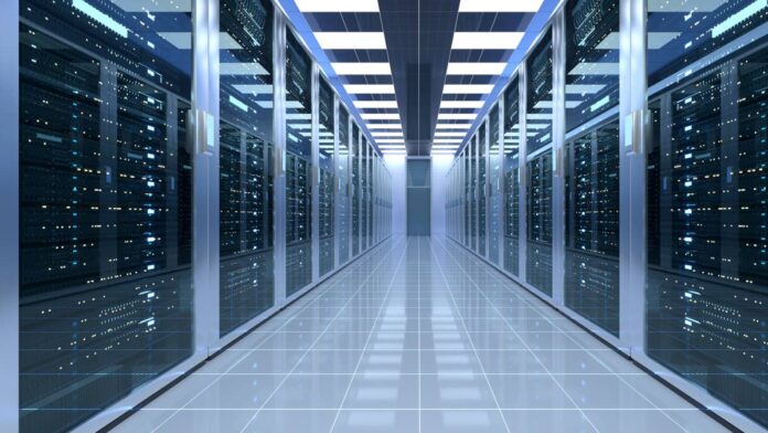 Cisco Systems Inc. (CSCO) has built its reputation on the routers and switches that move data between machines, not the machines themselves.
This week the company crossed that line. It is now selling AI server hardware directly, through a new partnership with Super Micro Computer Inc. (SMCI), a move that pulls Cisco deeper into a business it has traditionally left to others.
The <a href="https://newsroom.cisco.com/c/r/newsroom/en/us/a/y2026/m08/cisco-secure-ai-factory-nvidia-rack-scale.html">announcement</a> came Tuesday, August 25, when Cisco said it is expanding its Secure AI Factory with Nvidia architecture to include Supermicro’s liquid and air cooled server systems. Those systems will now be sold and validated as part of Cisco’s own AI infrastructure portfolio, not bolted on as a third party option.
The combined stack becomes compliant with Nvidia’s Cloud Partner program, the credential neoclouds and sovereign cloud operators look for before signing large contracts.
Cisco framed the timing around the scale of AI data center construction underway. Cisco President and Chief Product Officer Jeetu Patel said the industry is at the state of “one of the largest datacenter buildouts in history.”
<strong><a href="https://www.thestreet.com/technology/ai-accountability-problem-getting-bigger">Related: The AI accountability problem is getting bigger</a></strong>
That framing matters because Cisco is betting its growth on selling into that buildout as more than a networking vendor
Why Cisco needed a hardware partner
Cisco’s own hardware has always been networking gear, not the dense GPU servers that actually run AI workloads. Supermicro fills that gap with rack-scale systems built for Nvidia’s newest platforms, including the <a href="https://www.nvidia.com/en-us/data-center/vera-rubin-nvl72/">Vera Rubin NVL72</a>, a rack that can draw more than 200 kilowatts of power, according to <a href="https://siliconangle.com/2026/08/25/cisco-expands-rack-scale-secure-ai-factory-infrastructure-for-neocloud-and-sovereign-clouds/">SiliconANGLE</a>.
That power draw is the real constraint driving this deal. Air cooling alone cannot keep up with racks that dense, which is why the partnership centers on liquid cooling that links Cisco’s networking gear directly to Supermicro’s compute hardware.
Cisco says it is the only Nvidia technology partner building an NCP compliant architecture on its own networking silicon, according to the <a href="https://www.cisco.com/c/en/us/solutions/collateral/artificial-intelligence/cisco-secure-ai-factory-nvidia-rackscale-faq.html">company’s technical FAQ</a>.
That distinction matters commercially. It lets Cisco sell a fuller slice of the data center stack instead of competing purely on switches, where margins are thinner and rivals like Arista have been gaining ground.
Cisco is expanding its Secure AI Factory with Nvidia through a new Supermicro partnership, adding rack-scale liquid-cooled AI servers starting October 2026.<a href="https://www.gettyimages.com/detail/2278070804">Jason marz / Getty Images</a>
Wall Street buys the growth story
A Dow Jones 30 member, Cisco (CSCO) shares rose roughly <strong>1%</strong> Tuesday following the news. Wall Street’s broader view on Cisco is more bullish than that modest move suggests.
<strong>Also read: </strong><a href="https://www.thestreet.com/investing/dow-jones-industrial-index-companies-list"><strong>DJIA Master List: What companies make up the Dow Jones Industrial Index in 2026?</strong></a>
Twenty six analysts polled by S&P Global rate the stock a consensus <strong>Buy</strong> with an average price target near <strong>$133</strong>, implying meaningful upside from current levels, according to <a href="https://stockanalysis.com/stocks/csco/forecast/">Stockanalysis.com</a>.
That bullish consensus is clearly reflected at Morgan Stanley. In an August 24 report shared with TheStreet, analyst <a href="https://www.tipranks.com/experts/analysts/meta-marshall">Meta A. Marshall</a> reiterated an <strong>Overweight rating</strong> and a <strong>$135</strong> price target for Cisco, noting the company is entering a “more durable growth phase.” Crucially for this hardware pivot, Marshall pointed to upcoming “scale-across AI deployments” as a primary driver.
<strong>More Tech:</strong>
<a href="https://www.thestreet.com/technology/anthropic-powered-ai-model-luna-fires-employee"><strong>Anthropic-powered AI model sends shocking message to employee</strong></a>
<a href="https://www.thestreet.com/technology/rocket-lab-mda-space-satellite-launch"><strong>Rocket Lab clears 1st hurdle in its biggest satellite deal</strong></a>
<a href="https://www.thestreet.com/technology/apples-54-billion-iphone-machine-may-be-about-to-break-its-biggest-ritual"><strong>Apple’s $54 billion iPhone machine may be about to break its biggest ritual</strong></a>
With industry supply still tightly constrained, Morgan Stanley highlighted that Cisco’s massive balance sheet and direct procurement relationship with TSMC give it a distinct advantage in securing the components needed to actually execute on these dense server builds.
Supermicro’s high-growth, thin-margin reality
Supermicro’s reaction was sharper. SMCI jumped about <strong>9%</strong> Tuesday, a move <a href="https://247wallst.com/investing/2026/08/25/super-micro-surges-8-as-taiwan-indicts-employees-but-not-the-company-dell-climbs-4/">247wallst</a> attributed partly to the Cisco news and partly to unrelated legal clarity after Taiwanese prosecutors charged former associates without implicating the company itself.
Analyst sentiment remains more guarded than the stock pop implies. Nineteen analysts covering Supermicro rate it a consensus <strong>Hold</strong>, with an average price target near <strong>$42</strong>, according to <a href="https://stockanalysis.com/stocks/smci/forecast/">Stockanalysis.com</a>.
That caution sits awkwardly next to Supermicro’s actual numbers. The company’s fiscal fourth quarter revenue reached <strong>$11.1 billion</strong>, up from <strong>$5.8 billion</strong> a year earlier, while gross margin recovered to <strong>17.5%</strong> from <strong>9.5%</strong>, <a href="https://ir.supermicro.com/news/news-details/2026/Supermicro-Announces-Fourth-Quarter-and-Full-Fiscal-Year-2026-Financial-Results/default.aspx">according to Supermicro’s earnings release</a>.
Supermicro also guided fiscal 2027 revenue to a range of <strong>$65 billion</strong> to <strong>$72 billion</strong>, more than <strong>75%</strong> above this year at the midpoint. Analysts are still pricing in the risk that fast growth and thin margins have coexisted at Supermicro before, and could again.
The race for full-stack dominance
Cisco disclosed no committed order volume or pricing under the new arrangement, leaving the actual revenue impact unquantified for now.
The <a href="https://newsroom.cisco.com/c/r/newsroom/en/us/a/y2026/m08/cisco-secure-ai-factory-nvidia-rack-scale.html">combined architecture unifies</a> Cisco’s Silicon One and Nvidia’s Spectrum-X switch silicon under a single Cisco Nexus One design, a rare instance of a vendor supporting a rival’s networking chips inside its own reference architecture.
Supermicro’s systems become available through Cisco’s channel starting in October 2026, giving both companies a concrete date to show whether the partnership converts into actual orders.
This deal fits a pattern spreading across enterprise tech. Dell, HPE, and now Cisco are all racing to become full-stack AI infrastructure sellers rather than component vendors, because the AI buildout rewards companies that can offer compute, networking, cooling, and support as one purchase.
For Cisco, that shift is a bigger strategic pivot than the headline suggests. The company that once defined itself by staying out of the server business is now betting its next growth cycle on getting into it, and October will be the first real test of whether customers are buying.
<strong><a href="https://www.thestreet.com/investing/stocks/gs-goldman-sachs-partner-and-head-of-marquee-chris-churchman-warns-ai-could-erode-bankers-reasoning-skills">Related: Goldman Sachs partner sends urgent warning on what AI could destroy</a></strong>