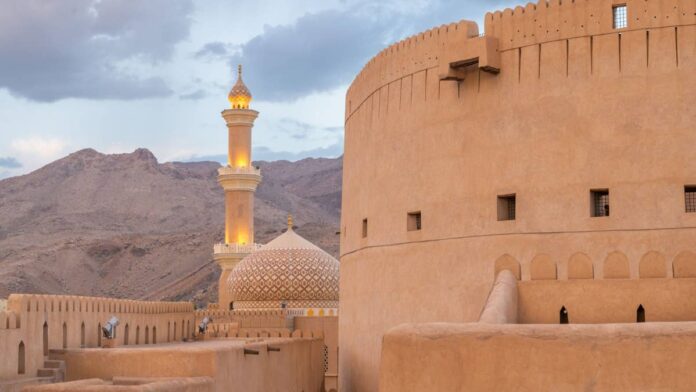 Sitting along the southeastern coast of the Arab Peninsula and sharing borders with the UAE, Yemen and Saudi Arabia, the Middle Eastern nation of Oman offers natural wonders like the bright turquoise valleys and river gorges known as <em>wadis</em>, the Hajar and Dhofar mountain ranges and a 12,500-square-kilometer desert region known as Sharqiya Sands.But with the regional dominance of Dubai, Oman is often overlooked as a travel destination. The instability in the Middle East set off by the <a href="https://www.thestreet.com/travel/major-airline-extends-refund-policy-for-dubai-flights">U.S.-Israeli strike on Iran earlier this year</a> has also significantly driven down tourism.As part of an effort to grow its tourism industry and encourage international travelers, the Omani government just scrapped its former requirement for an e-visa for travelers from more than 100 countries.Oman grants visitors of more than 100 countries 14 days of visa-free travelThe visa-free period for tourism-related visits has been set at 14 days and is granted to <a href="https://www.fm.gov.om/en/visitors/entry-visas/">citizens of countries including</a> the United States, the United Kingdom, Canada and the countries that are part of the European Union.While those seeking to stay longer or enter for purposes other than tourism or family visits will <a href="https://www.thestreet.com/travel/sri-lanka-makes-visas-free-to-travelers-from-40-countries">need to apply for a regular embassy visa</a> as before, anyone from the first group of approved countries is now able to simply buy a ticket to Oman and show up at the airport so long as they have a passport that will remain valid for at least six months at the time of entry.<strong><a href="https://www.thestreet.com/travel/united-states-government-new-warning-belgium-travel">Related: U.S. government issues strange new warning about Belgium travel</a></strong>The <a href="https://www.fm.gov.om/en/visitors/entry-visas/">second group of countries</a> for which the Omani government is easing entry requirements includes Algeria, Morocco, Guatemala and Mexico among others; citizens of these countries can also benefit from visa-free entry to Oman if they already hold a valid visa from countries including the U.S., Canada, the United Kingdom, Japan or one of the European Union countries.
Oman is a small country that sits on the southeastern tip of the Arab Peninsula.Getty
What else the changed entry rules mean for your Oman travelCitizens of the UAE, Bahrain, Kuwait, Qatar and Saudi Arabia, which are part of the Gulf Cooperation Council alliance alongside Oman, do <a href="https://www.thestreet.com/travel/this-country-is-introducing-a-new-visa-for-americans">not require a visa to enter</a> the country."In line with national efforts to promote and ease services for tourists visiting Oman, visitors from more than 100 countries and regions are exempt from entry visas for stays up to 14 days," the Foreign Ministry of Oman wrote of the changes.<strong>More Travel News</strong>:<a href="https://www.thestreet.com/travel/airline-to-launch-unusual-new-flight-to-cayman-islands-from-the-u-s"><strong>Airline to launch unusual new flight to Cayman Islands from the U.S.</strong></a><strong><a href="https://www.thestreet.com/travel/there-is-a-very-cool-irish-version-of-swimming-pigs-in-the-bahamas">There is a very cool Irish version of swimming pigs in the Bahamas</a></strong><a href="https://www.thestreet.com/travel/unexpected-country-is-most-luxurious-travel-destination-for-2026"><strong>Unexpected country is most luxurious travel destination for 2026</strong></a><a href="https://www.thestreet.com/travel/low-cost-airline-launches-easier-way-to-get-to-sri-lanka"><strong>Low-cost airline launches easier way to get to Sri Lanka</strong></a>According to government statistics, 1.8 million international tourists came to Oman in the first half of 2026 leading up to June. The largest number, 491,503 visitors, came from neighboring UAE while India was another major source of international tourism at 382,015 arrivals.Germany, Yemen and China were the other countries to land in the top five but tourism numbers in general have taken a hit of 9% since the start of the war in Iran.A report from the World Travel & Tourism Council estimated that the Middle Eastern tourism sector has <a href="https://www.omanobserver.om/article/1193803/oman/oman-receives-18m-tourists-in-the-first-half-of-2026">been losing nearly $600 million USD a day</a> as a result of flight cancelations, airspace closures and wider uncertainty around the war and potential retaliatory attacks from Iran.<strong><a href="https://www.thestreet.com/travel/a-country-is-partially-scrapping-visas-for-americans">Related: Global power is scrapping some visas for Americans</a></strong>