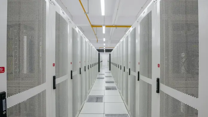 The loudest argument about Nebius Group is not about whether AI demand is real. Both sides agree it is. Michael Burry, who disclosed a short on <strong>NBIS</strong> on 6 August at roughly $212 and added to it on 12 August at $247, is not claiming that customers will stop buying GPU hours. He is claiming that the depreciation schedules underneath the reported profits are wrong. That distinction is the whole story, and it is why this stock can trade at $248.43 after a quarter in which revenue grew 454% year over year. The bulls are underwriting contracted revenue per megawatt. The bears are underwriting the useful life of a GPU. Those are different arguments about the same fleet, and only one of them resolves on the income statement. Our working bracket into 2027 is a <strong>$390 bull case</strong> against a <strong>$130 bear case</strong>, with spot at $248.43 as of the 18 August close.
Here is what almost every piece of NBIS coverage gets wrong: it treats the Q2 print as evidence for one side. It was evidence for both. The same release that produced a 50% adjusted EBITDA margin in the AI cloud business also disclosed a $5.66bn capex quarter, and capex is precisely the input that becomes the depreciation charge Burry is disputing. A blowout quarter in a capital-intensive business does not settle a depreciation argument — it enlarges it. Every incremental gigawatt Nebius commissions makes the accounting question bigger in absolute dollars, not smaller. That is the synthesis the bull-versus-bear framing usually misses, and it is the reason a $390 outcome and a $130 outcome can both be defended off the same set of audited numbers.
Key facts
Spot price <strong>$248.43</strong> at the 18 August 2026 close, down 7.6% on the session; 52-week range $62.01 to $299.86 — <em>stockanalysis.com, 19 August 2026</em>
Q2 2026 revenue <strong>$582.3m, up 454%</strong> year over year; AI cloud revenue $575m, up 514% — <em>Nebius Q2 2026 results, 11 August 2026</em>
AI cloud adjusted EBITDA margin reached <strong>50%</strong>; ARR moved from $1.9bn to $3bn inside 90 days — <em>Nebius Q2 2026 results</em>
Capex of <strong>$5.66bn</strong> in the quarter — the line that drives the depreciation dispute — <em>Nebius Q2 2026 results</em>
Michael Burry shorted at ~<strong>$212</strong> on 6 August, added at <strong>$247</strong> on 12 August: "Nebius is what the top of a boom looks like" — <em>Cassandra Unchained Substack, via Seeking Alpha</em>
Vineland, NJ planning board approved Phase 2 <strong>8-1</strong> on 18 August, clearing a gating risk on a <strong>$17.4bn</strong> Microsoft agreement — <em>WHYY, 18 August 2026</em>
Standard contract economics run <strong>$20m-$25m of revenue per megawatt</strong>; management says it has signed a first deal in the $40m-$50m per MW band — <em>Nebius Q2 2026 earnings call</em>
What is actually happening, and why the tape looks confused
Nebius sells AI compute capacity. The mechanism is closer to commercial property than to software: the company secures power and land, builds data centre shells, fills them with GPUs, and signs multi-year contracts against that capacity. Revenue per megawatt is the rent. The GPUs are the building. Depreciation is how you expense the building over its assumed life.
That framing explains the apparently contradictory tape. Revenue growth of 454% tells you the leasing side is working. A 7.6% drawdown on 18 August tells you the market is repricing something else — in this case the cost of financing the build and the assumptions underneath the reported margin. The stock peaked near $300 in mid-June, fell back toward the high $100s by late July, and has round-tripped to $248. That is not the price action of a settled thesis.
The funding mix matters more than most coverage allows. On the Q2 call the structure disclosed was roughly 40% of operating cash flow covered by customer prepayments, with asset-backed debt covering most of the remainder and the at-the-market equity programme acting as the marginal source of additional funding. Prepayments are the cheapest money in that stack and the most flattering to the equity story, because they arrive before the depreciation does. Asset-backed debt is priced against the same assets whose useful life is in dispute. If the depreciation assumption is wrong, the financing cost assumption is wrong in the same direction.
Nebius is not an isolated case here. The same argument runs through every neocloud balance sheet, which is why we mapped the sector-wide version of it in our <a href="https://financefeeds.com/ai-data-center-bear-case-99bn-backlog-50bn-debt/">AI data centre bear case on $99bn of backlog against $50bn of debt</a>. What separates Nebius from its peers is not the accounting question — it is the quality of the counterparties and the Nvidia relationship sitting behind the equity.
What the company, the Street and the short seller are each actually saying
The three constituencies are arguing past each other, and reading them side by side is more useful than picking one.
<strong>Management</strong> made one claim on the Q2 call that dominates the bull case: it could pre-sell its entire 2027 capacity today and is deliberately choosing not to, holding capacity back to capture higher yields from shorter-duration, premium demand. That is a statement about pricing power, and it is falsifiable — if 2027 capacity ends up contracted at standard rates, the claim was wrong. The company also disclosed it sees $40m-$50m per megawatt opportunities against a $20m-$25m standard, and has signed the first deal in that band.
<strong>The sell side</strong> moved up but not to euphoria. Baird raised its target to $340 from $250. Bank of America's Tal Liani went to $310 from $280 with a Buy rating. The 12-month average target across covering analysts sits around $272.56 — only 9.7% above spot. That is a Street that likes the business and is not underwriting a melt-up.
<strong>Burry</strong> is making a narrower and more technical claim than "AI is a bubble". His argument is that AI infrastructure operators are assuming useful lives for accelerators that are longer than the two-to-three-year real replacement cycle, which understates depreciation and overstates earnings. Note what he is not disputing: the revenue, the contracts, or the demand. Note also the structural caveat — Scion Asset Management is closed, so there are no 13F filings behind these positions. The disclosures come through his Cassandra Unchained Substack, which means the size of the position is not independently verifiable.
<blockquote>"Nebius is what the top of a boom looks like." — Michael Burry, Cassandra Unchained, 12 August 2026</blockquote>
There is a genuine counter to Burry from the operating side, and it is worth stating fairly: if A100s are still running economically into 2029, then a five-year schedule on newer H100 and B200 fleet is arguably conservative rather than aggressive. Second-hand utilisation of prior-generation accelerators is the empirical test, and it has so far run in the operators' favour. This is the crux, and it will be resolved by resale markets, not by argument.
The numbers: where $390 and $130 actually come from
NBIS over 12 months to 18 August 2026. Spot $248.43, with the $390 bull and $130 bear scenarios marked. Price data: stockanalysis.com.
<strong>The $390 bull case</strong> is a revenue-per-megawatt argument. Nebius exited Q2 with $3bn of ARR, having added $1.1bn of it in a single quarter. If the premium band it has begun signing — $40m to $50m per MW against a $20m to $25m standard — becomes a meaningful share of the 2027 book rather than a single deal, the revenue per unit of commissioned capacity roughly doubles without any additional gigawatts. Layer that onto an AI cloud business already running a 50% adjusted EBITDA margin, and you reach a number above the highest published Street target of $340. That is $390, or 57% above spot. It requires the pricing claim to be true at scale and the capacity to actually come online.
<strong>The $130 bear case</strong> is the depreciation argument carried to its conclusion. If the economic life of the fleet is two to three years rather than five to six, the annual depreciation charge against a $5.66bn quarterly capex run-rate roughly doubles. A 50% adjusted EBITDA margin survives that — adjusted EBITDA sits above depreciation — but reported earnings and free cash flow do not, and the multiple the market is willing to pay compresses accordingly. The level is not arbitrary: NBIS traded through $130 as recently as March and April 2026. The bear case is not a crash to an unprecedented level. It is a round trip to where the stock sat five months ago, which the chart above makes plain.
Both brackets sit either side of spot, and that is deliberate. A prediction page whose bull case is below the current price is not a prediction — it is a stale artefact. Readers should treat any NBIS target published before the 11 August Q2 release as pre-dating the single most important disclosure in the company's history as a listed AI cloud operator.
For context on how the same maths lands on comparable balance sheets, our <a href="https://financefeeds.com/coreweave-crwv-price-prediction-q2-earnings-106-bull-79-bear/">CoreWeave CRWV bull and bear analysis</a> and our <a href="https://financefeeds.com/iren-stock-prediction-84-bull-case-22-bear-case/">IREN $84 bull versus $22 bear breakdown</a> run the identical framework across two peers with materially different funding structures.
The regulatory and permitting tension nobody priced until this week
On the night of 18 August, Vineland's planning board approved DataOne's 587,980 square foot Phase 2 expansion by a vote of 8-1, after public comment ran past 11pm. Phase 1 is already under construction. The approval matters financially because dedicated capacity from that New Jersey site underpins a multi-year Microsoft agreement valued at $17.4bn — the approval removed a genuine execution risk rather than merely adding a site.
It also showed where the binding constraint on this entire sector now sits. The vote drew boos from the room and a shout of "You sold us out!" from residents who said they had been blindsided by a plan amended several times. The objections were specific: noise, water consumption, emissions, LNG storage on site, and the sheer scale of the build.
This is the part of the AI infrastructure trade that does not appear in any DCF. Nebius has secured up to 1.2 gigawatts of power and land for a planned Pennsylvania facility and talks about a pipeline running toward 5 gigawatts. Every one of those gigawatts has to clear a local planning board somewhere, in front of residents who bear the water and emissions cost and capture none of the compute upside. An 8-1 vote is comfortable. It is not a guarantee that the next one goes the same way, and the political economy is moving against permissive approvals, not toward them.
For an investor, the correct read is that permitting has migrated from a background assumption to a live gating item on the growth schedule. That is a change in the risk profile even though this particular vote went the company's way.
What happens next
<strong>First, the depreciation question gets settled empirically, not rhetorically, and probably during 2027.</strong> The test is whether prior-generation accelerators retain economic utility past the five-year mark. If A100-class hardware is still generating revenue in 2029, Burry's thesis fails on its own terms and the bear case decays toward the low $200s rather than $130. If resale values break down first, reported earnings across the entire neocloud cohort reset simultaneously.
<strong>Second, watch the 2027 contract mix rather than the headline growth rate.</strong> Management has staked its credibility on being able to sell 2027 capacity at premium, shorter-duration rates. The disclosure to look for is realised revenue per megawatt, not total revenue. Revenue can grow 400% while unit economics deteriorate; that combination is what a genuine top would look like.
<strong>Third, expect permitting to become a disclosed risk factor rather than an operational footnote.</strong> After Vineland, the marginal gigawatt is a political question. We would expect the next several site announcements to arrive with more community-engagement framing attached, and we would treat any site that slips more than two quarters as a leading indicator on the 5 gigawatt ambition.
Our base case is that NBIS spends the next two quarters range-bound between the March lows and the June highs while the market waits for the 2027 contract mix to become visible. The bracket resolves toward $390 if premium pricing holds at scale, and toward $130 if depreciation schedules are revised — and, critically, those are the only two disclosures that matter. Everything else is noise around a fleet whose useful life nobody has yet proven.
Frequently asked questions
<strong>What is the Nebius NBIS stock prediction for 2027?</strong>
Our bracket is a $390 bull case against a $130 bear case, with spot at $248.43 as of the 18 August 2026 close. The bull case requires premium revenue-per-megawatt pricing to hold across the 2027 book. The bear case requires depreciation schedules on the GPU fleet to be revised toward a two-to-three-year economic life. Analyst consensus sits near $272.56, with Baird at $340 and Bank of America at $310.
<strong>Why is Michael Burry short Nebius?</strong>
Burry's argument is an accounting one, not a demand one. He contends AI infrastructure operators assume useful lives for accelerators that exceed the real two-to-three-year replacement cycle, which understates depreciation and overstates earnings. He disclosed the short on 6 August at around $212 and added at $247 on 12 August. Because Scion Asset Management is closed, there are no 13F filings and position size cannot be independently verified.
<strong>How did Nebius perform in Q2 2026?</strong>
Revenue rose 454% year over year to $582.3m, with AI cloud revenue of $575m up 514%. The AI cloud segment posted a 50% adjusted EBITDA margin, and annualised run-rate revenue moved from $1.9bn to $3bn within the quarter. Capex was $5.66bn. Full detail is in our <a href="https://financefeeds.com/nebius-nbis-q2-2026-result-stock-up-backlog-capex/">Nebius Q2 2026 results coverage</a>.
<strong>What did the Vineland approval actually change?</strong>
The 18 August 8-1 planning board vote approved a 587,980 square foot Phase 2 expansion and removed a gating execution risk on a $17.4bn Microsoft agreement that depends on capacity from the site. It did not resolve the underlying community objections over water, emissions and LNG storage, which remain a template for opposition at future sites.
<strong>Is Nvidia's stake in Nebius relevant to the valuation?</strong>
Nvidia holds a 9.3% beneficial ownership position, disclosed via regulatory filing, on top of an earlier $2bn investment. It is a meaningful signal about supply access and strategic alignment, but it is not a floor under the share price. We covered the stake and its lock-up mechanics separately in our <a href="https://financefeeds.com/nebius-nbis-nvidia-stake-bullish-410-bearish-120/">analysis of the Nvidia position in Nebius</a>.
<strong>What is the single number to watch from here?</strong>
Realised revenue per megawatt on 2027 contracts. Standard economics run $20m-$25m per MW and management claims it has signed a first deal in the $40m-$50m band. If that premium becomes the mix rather than the exception, the bull case is live. If 2027 contracts land at standard rates, the growth is real but the multiple is not.
<em>Sources: <a href="https://stockanalysis.com/stocks/nbis/">stockanalysis.com</a> for price and range data; <a href="https://seekingalpha.com/news/4632100-burry-adds-to-ai-shorts-says-nebius-is-what-the-top-of-a-boom-looks-like">Seeking Alpha</a> on the Burry position; <a href="https://whyy.org/articles/vineland-planning-board-approves-data-center-plan/">WHYY</a> on the Vineland planning board vote; <a href="https://nebius.com/vinelandnj">Nebius</a> on the Vineland project.</em>
<em>This article is analysis and information only. It is not investment advice, and it is not a recommendation to buy or sell any security. The bull and bear figures are scenario brackets, not price targets. Figures are accurate as at the 18 August 2026 close and market conditions change.</em>