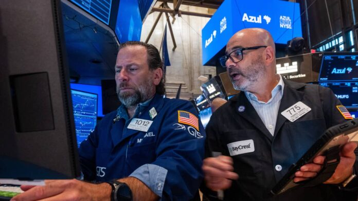 JPMorgan Chase just had the most profitable quarter in its history. Second-quarter net income came in at $21.2 billion, powered by a surge in trading revenue and a gain on its Visa stake. The <a href="https://www.thestreet.com/dictionary/s/s-p-500">S&P 500</a> is up close to 10% this year. Consumers are still spending. Inflation has moderated. By most measures, the market's mood is good.<a href="https://www.thestreet.com/tag/jamie-dimon">Jamie Dimon</a> doesn't share it. In an <a href="https://www.cnbc.com/2026/07/21/jpmorgan-chase-ceo-jamie-dimon-market-risk.html">hourlong interview with CNBC</a> contributor Wilfred Frost on his "Master Investor" podcast, recorded July 16 and released July 21, the JPMorgan CEO said he would "absolutely not" buy the broad stock market at current prices. He also wouldn't buy long-dated U.S. Treasurys. And he thinks investors are underestimating a long list of risks building underneath the surface.<strong>What JPMorgan says about stocks and current market valuations</strong>Dimon's position on stocks is direct. He would consider buying individual companies if he found something genuinely attractive. But on the broader market, at current levels, he's out. "I do think those risks are probably bigger than other people think," he said, <a href="https://www.cnbc.com/2026/07/21/jpmorgan-chase-ceo-jamie-dimon-market-risk.html">CNBC reported</a>.<strong>More JPMorgan:</strong><a href="https://www.thestreet.com/investing/stocks/jpmorgan-raises-eli-lilly-stock-price-target-1400"><strong>JPMorgan resets LLY stock target on drug demand</strong></a><a href="https://www.thestreet.com/investing/jpmorgan-cuts-silver-price-target-investors"><strong>JPMorgan sees the writing on the wall for silver stock investors</strong></a><a href="https://www.thestreet.com/economy/jpmorgan-doubles-down-on-economy-inflation-outlook"><strong>JPMorgan doubles down on economy, inflation outlook</strong></a>The market has largely been shrugging off shocks that would have rattled it in earlier cycles. Wars in Ukraine and the Middle East, trade friction, political instability, and rising government deficits have all come and gone as headline risks without meaningfully denting prices. Dimon thinks that streak of resilience has made investors too comfortable, and he's been sounding this alarm for months.<strong>Why the AI spending boom may not pay off on Wall Street's timeline</strong>One of the sharpest stock market observations in Dimon's interview was about artificial intelligence. He drew a direct parallel between the current <a href="https://www.thestreet.com/tag/artificial-intelligence">AI</a> spending wave and the internet boom of the late 1990s, and the comparison wasn't flattering."Will it in total pay off? Probably, just like the internet did," he said. "Will it pay off the way you expect and the timetable you expect? Definitely not," he added, according to <a href="https://www.foxbusiness.com/markets/jamie-dimon-says-he-wouldnt-buy-stocks-treasurys-current-prices">Fox Business</a>.Companies are spending enormous amounts on AI infrastructure with uncertain and potentially delayed returns. The S&P 500's gains this year have been heavily driven by technology stocks pricing in AI upside. If Dimon's dot-com analogy holds, the spending will eventually pay off, but the timeline and the companies that benefit may look very different from what investors currently expect. That has direct implications for some of the most heavily weighted names in the index.
Dimon's reluctance to own long-dated government debt is as notable as his stock market caution.Spencer/Getty Images
<strong>Why long-dated Treasury bonds are not a safe bet right now</strong>Dimon's reluctance to own long-dated government debt is as notable as his stock market caution. Treasurys are the default safe-haven trade when equity investors get nervous. If he's not comfortable buying them either, the usual flight-to-safety playbook breaks down.His reasoning is specific. Even if <a href="https://www.thestreet.com/dictionary/i/inflation">inflation</a> fell back to the <a href="https://www.thestreet.com/dictionary/f/federal-reserve">Federal Reserve</a>'s 2% target, Dimon said the 10-year Treasury <a href="https://www.thestreet.com/dictionary/y/yield">yield</a> should still be in the 4% to 4.5% range. The 10-year is currently yielding around 4.6%, which leaves almost no room for prices to rise. He expects so-called bond vigilantes to keep demanding higher yields to finance growing government debt, keeping pressure on long-duration bonds, <a href="https://www.cnbc.com/2026/07/21/jamie-dimon-stock-bond-market-warning-treasuries.html">CNBC reported</a>. "My view is that this will eventually become a big problem," he said of the fiscal deficit.Stock investors should pay attention to this, too. When Treasurys were a reliable safe haven, the playbook was simple: rotate out of stocks during a selloff and into bonds. Dimon says this trade doesn't work as cleanly as it used to. It leaves investors with fewer good options if equity markets do correct, <a href="https://www.thestreet.com/investing/stocks/jpmorgan-jamie-dimon-stock-market-message-2026">as TheStreet reported</a> in its coverage of Dimon's May 2026 remarks at the Reagan National Economic Forum.<strong>The geopolitical and fiscal risks keeping JPMorgan on the sidelines</strong>Dimon named four specific risk clusters in the interview: the wars in Ukraine and the Middle East, U.S.-China tensions, rising military spending by governments, and expanding budget deficits. He doesn't think the market is adequately pricing any of them.He didn't predict an imminent crash. "It may take more straws to break the camel's back," he said. "Even a further escalation of current wars may not be enough to be the trigger." The economy has gotten more resilient, Dimon said, and shocks that would have rattled markets in earlier cycles have been absorbed. His concern is that the market is treating that resilience as a permanent condition.JPMorgan is not struggling. It just posted record profits. Dimon ran through these same warnings for most of 2026, and the S&P 500 kept climbing. He knows that. What he's saying now is that prices have run up to a level where there's not much cushion left if something goes wrong. The CEO of the most profitable bank in U.S. history is passing on the broad market. Most investors probably won't. But the signal is worth keeping in mind.<strong><a href="https://www.thestreet.com/economy/jp-morgan-ceo-has-blunt-inflation-message">Related: JP Morgan CEO has blunt inflation message</a></strong>