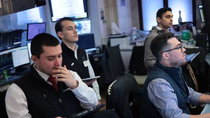 Stocks are already up more than 10% this year. Most strategists would call that a good run and leave it alone. Wells Fargo looked at the same market and decided it wasn't done yet.The bank raised its year-end 2026 target for the <a href="https://www.thestreet.com/dictionary/s/s-p-500">S&P 500</a> to 7,950, up from 7,300, implying roughly 5.2% more upside from the index's June 16 close near 7,554, <a href="https://seekingalpha.com/news/4605019-wells-fargo-raises-s-and-p-500-price-target-says-ai-bull-market-is-likely-to-continue">Seeking Alpha</a> reported. <a href="https://www.bloomberg.com/news/articles/2026-06-16/wells-fargo-boosts-s-p-500-year-end-target-as-us-iran-deal-nears">Bloomberg</a> confirmed the call came in a note dated June 15. Chief equity strategist Ohsung Kwon summed up the bank's view directly."The path of direction for the equity market is still higher."<strong>Why the new S&P 500 target is about earnings, not hype</strong>Here's the important part. Wells Fargo didn't just decide to feel more optimistic. The bank raised its 2026 S&P 500 earnings-per-share estimate to $340 from $315 and bumped 2027 up to $390 from $365, <a href="https://www.gurufocus.com/news/8918748/wells-fargo-raises-sp-500-target-to-7950-on-ai-boom">GuruFocus</a> reported. Do the math on that, and the new target works out to roughly 23.4 times 2026 earnings, barely higher than the 23.2x multiple baked into the old target.<strong>More <a href="https://www.thestreet.com/dictionary/w/wall-street">Wall Street</a>:</strong><a href="https://www.thestreet.com/investing/stocks/hsbc-doubles-down-bullish-stock-market-message-2026"><strong>HSBC doubles down on stock market message for 2026</strong></a><a href="https://www.thestreet.com/investing/citi-quietly-resets-sp-500-price-target-for-the-rest-of-2026"><strong>Citi quietly resets S&P 500 price target for the rest of 2026</strong></a><a href="https://www.thestreet.com/investing/stocks/jim-cramer-has-a-stark-message-on-the-stock-market-for-2026"><strong>Jim Cramer has a stark message on the stock market for 2026</strong></a>A bank can raise a price target for two different reasons. It can think investors will pay more for the same dollar of earnings, or it can think the earnings themselves are about to go up. Wells Fargo is doing the second one. Almost the entire upgrade comes from higher expected profits, not investors getting more excited and paying up for the same stocks. A forward multiple in the low 23s is elevated against long-run averages near 17 or 18 times earnings, but it's not unusual when investors expect a durable, multi-year profit cycle rather than a one-quarter pop.<strong>Why Wells Fargo thinks the market backdrop just got easier</strong>That 7,300 starting point has a backstory. Kwon had actually cut Wells Fargo's target down to 7,300 from 7,800 back in late March, when the Iran conflict was escalating and the firm's own war-risk model showed stocks pricing in more geopolitical danger than oil-price danger for the first time, <a href="https://www.investing.com/news/analyst-ratings/wells-fargo-raises-yearend-sp-500-price-target-to-7950-93CH-4745378">Investing.com</a> reported. The new 7,950 target effectively erases that cut and then some.Two things changed Wells Fargo's mind beyond the earnings math. The U.S. and Iran reached an interim understanding that's eased some of the geopolitical pressure that had been weighing on markets, and a recent selloff in equities actually helped, resetting investor positioning closer to neutral rather than overheated. A market that just cooled off has more room to run than one that's already crowded with everyone leaning the same direction.Wells Fargo still flagged <a href="https://www.thestreet.com/dictionary/i/inflation">inflation</a> as the main risk to watch. But the bank's view is that stocks could actually work as a hedge in that scenario, too, if the Fed ends up letting the economy run a little hot rather than slamming the brakes.
Wells Fargo isn't pretending the market is cheap. The bank has openly acknowledged froth in parts of it.M.Santiago/Getty Images
<strong>The AI stocks bet underneath Wells Fargo's S&P 500 call</strong>Strip away the macro commentary, and what's left is a very specific bet on continued <a href="https://www.thestreet.com/tag/artificial-intelligence">AI</a> spending. Wells Fargo kept a constructive view on cyclical stocks, semiconductors, and infrastructure names tied to the AI buildout. Kwon pointed to continued heavy capital spending from companies like Alphabet and Meta as a positive signal for what he calls "CapEx takers," the semiconductor makers and infrastructure providers who benefit when hyperscalers keep building.Kwon also pushed back on a worry that's been floating around the AI trade, the idea that falling token prices for AI models might eventually hurt the companies selling the infrastructure underneath them. His counter is that cheaper AI models could actually increase total demand for computing power rather than shrink it, since more applications become economically viable to build."I think we're still in the very early phase of the AI adoption," he <a href="https://www.cnbc.com/2026/06/16/this-will-be-the-summer-of-the-everything-rally-says-wells-fargo.html">told CNBC</a>.During the recent market turbulence, semiconductor and AI infrastructure stocks actually held up better than the rest of the market, while other sectors took the hit. Wells Fargo reads this not as a warning sign, but as evidence that the underlying trend is still intact.Wells Fargo Investment Institute, the bank's wealth management arm, moved in the same direction. It adjusted its own year-end S&P 500 target range to 7,800 to 7,950, up from a prior range of 7,400 to 7,950, and set a 2027 target range of 8,600 to 8,800, according to <a href="https://www.gurufocus.com/news/8918748/wells-fargo-raises-sp-500-target-to-7950-on-ai-boom">GuruFocus</a>. Two parts of the same bank landing on a similar conclusion independently is the kind of thing that tends to carry more weight than a single strategist's call.<strong>Wells Fargo isn't pretending the rally is risk-free</strong>Wells Fargo isn't pretending the market is cheap. The bank has openly acknowledged froth in parts of it, and certain names have clearly run further than their <a href="https://www.thestreet.com/dictionary/f/fundamentals">fundamentals</a> alone would justify. But froth in pockets and an overheated market overall are two different things, and Wells Fargo's argument is that the second one isn't true yet.Practically, that means the takeaway isn't "buy everything" or "sell everything." It's closer to: stay selective, because some of what's rallied hardest may have gotten ahead of itself, while the broader earnings engine driving the market still has fuel left in the tank.<strong>What could break Wells Fargo's S&P 500 bull case</strong>The whole call rests on AI capital spending staying strong. If that spending slows down meaningfully in the next few quarters, the earnings growth Wells Fargo is counting on doesn't show up, and a 23.4x multiple on disappointing profits looks a lot less comfortable than 23.4x on growing ones.Corporate earnings beats matter here, too. Wells Fargo's case depends on companies actually delivering the profit growth baked into those new EPS numbers, not just promising it on earnings calls. And market breadth is worth watching closely. If the gains stay concentrated in a small group of AI-linked names, the rally stays fragile, no matter how good the headline target looks. If more sectors start participating, that's the stronger signal that Wells Fargo's broader thesis is playing out the way the bank expects.<strong><a href="https://www.thestreet.com/investing/goldman-sachs-doubles-down-on-sp-500-message-for-2026-raise-target-index">Related: Goldman Sachs doubles down on S&P 500 message for 2026</a></strong>