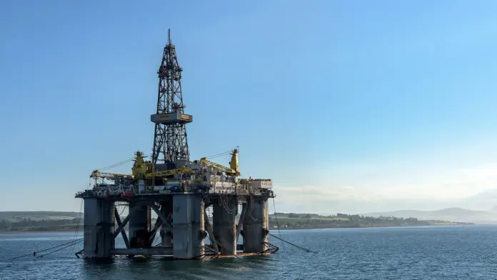 <strong>Updated 24 September 2026.</strong> Brent crude trades at <strong>$103.67</strong> a barrel, up 0.57 percent on the day and 18.79 percent over the past month, according to TradingEconomics market data on 24 September. WTI is at $92.66. <strong>Verdict:</strong> the oil market has spent a week pricing the wrong tail. Prediction-market traders have put $74 million into the question of whether Iran keeps Kharg Island, the terminal that loads roughly 90 percent of its crude exports, and the answer they keep arriving at is <em>yes, comfortably</em>. The near-dated legs resolving 30 September and 1 October sit at about 1 percent. What the same board prices as genuinely uncertain is far duller and far more expensive: whether the Strait of Hormuz ever goes back to normal. That leg is 22 percent by year-end.
Key facts
<strong>Brent: $103.67</strong> (+0.57 percent), <strong>WTI: $92.66</strong> (+0.55 percent) - TradingEconomics, 24 September 2026. Brent is up 51.17 percent year on year.
Brent closed 23 September at <strong>$101.61</strong>, a 2.37 percent jump, after Iranian President Masoud Pezeshkian told the UN General Assembly that Iran will not permit freedom of navigation through Hormuz while US sanctions and the port blockade remain.
<strong>Kharg Island handles about 90 percent of Iran's oil exports</strong> and has roughly <strong>7 million barrels per day of loading capacity</strong> (Argus Media explainer; Britannica).
Polymarket's "Kharg Island no longer under Iranian control" market has taken <strong>$74 million in total volume and $487,000 in the last 24 hours</strong>. It prices the year-end leg at <strong>6 percent</strong> and the 30 September / 1 October legs at about <strong>1 percent</strong> (Polymarket, checked 24 September).
"Strait of Hormuz traffic returns to normal" prices at <strong>1 percent by 30 September, 8 percent by 31 October, 13 percent by 30 November and 22 percent by 31 December</strong>, on $13 million of volume in the year-end leg alone.
HSBC raised its 2026 Brent forecast to <strong>$90 from $80</strong> on 10 September; its stalemate case is <strong>$120</strong> (analyst Kim Fustier).
The $74 million question nobody is actually asking
Kharg Island is a 20-square-mile rock in the northern Persian Gulf that functions as the single point of failure for Iranian crude. Argus Media's explainer on the terminal and Britannica's entry both put its loading capacity near 7 million barrels per day, and reporting through the summer consistently placed roughly 90 percent of Iran's seaborne exports through its jetties. Loadings resumed at the western terminal on 12 August after a 25-day shutdown caused by the Hormuz blockade, and between 19 and 21 September a VLCC capable of carrying up to 2 million barrels departed Iran's Jask terminal in the Gulf of Oman - the workaround route that sits outside the Persian Gulf entirely.
That combination - a terminal that is both indispensable and militarily exposed - is why the Kharg market became one of the largest on Polymarket's board. It is also why the pricing matters. Traders have put $74 million behind the question and settled on roughly a 6 percent chance that the island leaves Iranian hands by 31 December, and about 1 percent for the legs resolving next week. The adjacent island markets - Farsi, Hengam, Hormuz, Abu Musa, Greater Tunb - all sit at 1 percent for 1 October on volumes between $55,000 and $208,000.
The distinction the board is drawing is between striking a target and holding one. Iran's export terminals have been hit and shut before. Occupying Iranian territory is a categorically different act, with a different escalation ladder attached, and the money says it is not happening this quarter. For an oil trader that is a specific and useful statement: the $150-a-barrel outcome that requires Iran's export hub to change hands is priced at roughly one-in-sixteen by year-end, and roughly one-in-a-hundred by next Tuesday.
What the board says is actually uncertain
Move one market across on the same page and the confidence disappears. "Strait of Hormuz traffic returns to normal" is priced at 1 percent for 30 September, 8 percent for 31 October, 13 percent for 30 November and 22 percent for 31 December - and the year-end leg carries $13 million of volume, the second-largest pool in the complex after Kharg itself. Traders are not betting on a catastrophe. They are betting, with real conviction, on a grind.
Two related markets fill in the shape of that grind. "Iran-Oman Hormuz Management Agreement by 31 October" prices at 34 percent on $3 million, and "Iran charges Hormuz fees by 31 December" prices at 28 percent on another $3 million. Read together, that is a market assigning better than one-in-three odds to a negotiated transit regime in which the waterway reopens on terms - and on a toll. "Bab el-Mandeb Strait effectively closed by 31 December" sits at 18 percent on $15 million, a reminder that the Red Sea leg of the same problem has not gone away.
Two headlines from this week map directly onto those numbers. On 22 September a senior Iranian official told Reuters that Iran could reopen Hormuz within seven days if the United States eased military pressure and lifted the blockade on Iranian ports. On 23 September, at the UN General Assembly, Pezeshkian made the condition explicit, saying Iran cannot accept that everyone benefits from the waterway while its historic guardian is deprived by sanctions. That is not a threat to close the strait. It is an opening price for reopening it - which is precisely what a 34 percent management-agreement line and a 28 percent transit-fee line describe.
What that leaves in the price
HSBC's Kim Fustier framed the same picture in flow terms on 10 September, raising the bank's 2026 Brent forecast to $90 from $80. Her numbers: roughly 6 million barrels per day is currently moving through Hormuz, drifting toward about 8 million by end-2026 and 9.5 million by mid-2027, against 19 to 20 million before the war. HSBC does not expect the market to rebalance until around the middle of 2027, and describes a disrupted "new normal" in which the strait is neither closed nor open but persistently impaired. The bank's stalemate case - diplomacy fails, flows stay constrained - is $120.
Goldman Sachs has warned separately that prices could reach $120 if attacks on Middle East shipping intensify. Citi's April work put a $150 tail on the scenario in which flows stay disrupted, assigning roughly 30 percent to its bull case at the time. Bank of America has been the conservative outlier, at $83 for the second half of 2026.
With Brent at $103.67, the market is already trading above every published base case except the stalemate ones. That is the uncomfortable part: spot is not pricing HSBC's $90 world, it is pricing something between the base case and the stalemate, and it got there mostly on the strength of a UN speech. For more on the pipeline workarounds that have been capping the upside, see our coverage of the <a href="https://financefeeds.com/crude-oil-price-houthis-mocha-bab-el-mandeb/">Bab el-Mandeb and Saudi rerouting math</a>.
Scenarios into year-end
CaseBrentvs spot ($103.67)Anchor
<strong>Bear</strong><strong>$90</strong>-13.2 percentHSBC's published 2026 base case, raised from $80 on 10 September (Kim Fustier). Requires the fragile US-Iran understanding to hold and Hormuz flows to drift toward 8m bpd on schedule. The Polymarket board gives the "traffic returns to normal by 31 December" leg 22 percent.
<strong>Base</strong><strong>$104</strong>flatThe board's own modal path: no change of control at Kharg (about 94 percent by year-end), no return to normal traffic (78 percent), and a one-in-three chance of a negotiated transit regime with fees. Impaired, open, expensive.
<strong>Bull</strong><strong>$120</strong>+15.8 percentHSBC's stalemate case and Goldman Sachs' escalation warning converge here: diplomacy fails, shipping attacks intensify, flows stay near 6m bpd. Citi's separate $150 tail sits above this and requires a supply event at an export terminal - the outcome the Kharg market prices at 6 percent.
<em>Scenario anchors are published analyst forecasts with their dates, and prediction-market prices checked on 24 September 2026. They are not FinanceFeeds price targets.</em>
Quick take
Brent at $103.67 is carrying a war premium for a war outcome that the deepest prediction market on the subject prices at roughly 1 percent this week. What is not priced out is the boring version: a strait that stays half-shut into 2027, flows at 6 million barrels a day against a pre-war 19 to 20 million, and a one-in-three chance the reopening comes with a toll attached. If you are long oil on the Kharg headline, you are long a 6 percent event. If you are long oil on Hormuz staying broken, the board is on your side at 78 percent - and so is HSBC's mid-2027 rebalancing date.
FAQ
What is Brent crude trading at today?
Brent is at $103.67 a barrel as of 24 September 2026, up 0.57 percent on the day, per TradingEconomics. WTI is at $92.66. Brent is up 18.79 percent over the past month and 51.17 percent year on year.
Why does Kharg Island matter to the oil price?
Kharg is the loading terminal for roughly 90 percent of Iran's crude exports, with about 7 million barrels per day of loading capacity. A loss of the terminal would remove Iran's primary route to the seaborne market almost overnight, which is why it is the single most-traded geopolitical question on Polymarket's Iran board.
What odds is Polymarket giving on Kharg Island?
About 1 percent for the legs resolving 30 September and 1 October, and 6 percent for a change of control by 31 December, on $74 million of total volume and $487,000 traded in the last 24 hours, checked 24 September 2026. Odds move continuously - verify at the source before acting on them.
When will the Strait of Hormuz reopen?
Nobody knows, and the market says not soon. Polymarket prices a return to normal traffic at 1 percent by 30 September, 8 percent by 31 October, 13 percent by 30 November and 22 percent by 31 December. HSBC does not expect the oil market to rebalance until around mid-2027. A senior Iranian official told Reuters on 22 September that Iran could reopen the strait within seven days if the US eased military pressure and lifted its port blockade.
What are analysts forecasting for Brent?
HSBC raised its 2026 Brent forecast to $90 from $80 on 10 September, with a $120 stalemate case. Goldman Sachs has warned of $120 if shipping attacks intensify. Citi's April work carried a $150 tail. Bank of America has been at $83 for the second half of 2026. Spot is currently above all of the base cases.
Could Brent reach $150?
Citi has put that number on the scenario where Hormuz flows stay disrupted. Mechanically it requires a genuine supply event rather than a risk premium - most plausibly an interruption at an export terminal. The prediction market prices a change of control at Kharg at 6 percent by year-end, which is the closest available read on how likely traders think that specific path is.
How much Iranian oil is still moving?
Loadings resumed at Kharg's western terminal on 12 August after a 25-day shutdown. Between 19 and 21 September a VLCC able to carry up to 2 million barrels departed the Jask terminal in the Gulf of Oman, Iran's route that bypasses the Persian Gulf. HSBC estimates roughly 6 million barrels per day is currently transiting Hormuz overall, against 19 to 20 million before the war.
Related coverage
<a href="https://financefeeds.com/brent-crude-oil-price-98-below-100-hormuz-reopening-bull-bear/">Brent crude below $100 and the Hormuz reopening trade</a>
<a href="https://financefeeds.com/brent-crude-oil-price-98-trump-midterms-iran-deal-bull-120-bear-90/">Brent at $98 as Trump says an Iran deal waits for the midterms</a>
<a href="https://financefeeds.com/wti-crude-oil-price-115-bull-80-bear-hormuz/">WTI crude scenarios: $115 bull, $80 bear on Hormuz</a>
<strong>Sources:</strong> TradingEconomics (Brent and WTI quotes, 24 September 2026); Polymarket Kharg Island and Strait of Hormuz market pages (odds and volumes checked 24 September 2026); Argus Media explainer on Kharg Island; Britannica; Bloomberg (Pezeshkian UN General Assembly address, 23 September 2026); Reuters (senior Iranian official on a seven-day reopening, 22 September 2026); OilPrice.com reporting on HSBC's 10 September forecast revision (analyst Kim Fustier); The National (Kharg loading resumption, 16 August 2026).
<em>This article is for information only and is not investment advice. Commodity prices and prediction-market odds move continuously and the figures above were accurate at the time of writing. Nothing here is a recommendation to buy or sell any instrument. Do your own research and consider your own circumstances before trading.</em>