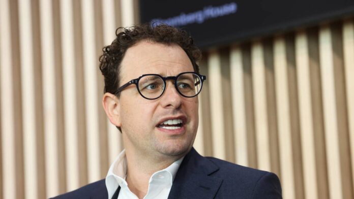 Microsoft has spent the past year watching Anthropic and OpenAI pull ahead in the race to make AI genuinely useful for corporate customers.
On September 25, the company tried to close that gap in one move. It folded years of separate AI products into a single app built to compete directly with Claude.
The timing is not incidental.
Microsoft’s stock has trailed most of its megacap peers this year. The redesign is a bet that a simpler, more unified product can finally turn Copilot adoption into the kind of growth investors have been waiting for.
<strong>Microsoft redesigned Copilot to challenge Anthropic’s Claude</strong>
The updated app is organized around three sections. Home combines conversational chat with a task-delegation feature called Cowork. It also embeds full versions of Word, Excel and PowerPoint so users can create and edit documents without leaving the app.
The second section, called Code, lets users build apps, dashboards, and other software using natural language prompts, built on the same technology that powers GitHub Copilot, <a href="https://www.cnbc.com/2026/09/25/microsoft-copilot-ai-coding-anthropic.html">according to CNBC.</a>
<strong>More Microsoft:</strong>
<a href="https://www.thestreet.com/investing/stocks/morgan-stanley-microsoft-stock-forecast-ahead-of-earnings"><strong>Morgan Stanley resets Microsoft stock forecast ahead of earnings</strong></a>
<a href="https://www.thestreet.com/investing/stocks/bank-of-america-doubles-down-on-microsoft-stock-ahead-of-earnings"><strong>Bank of America doubles down on Microsoft stock ahead of earnings</strong></a>
<a href="https://www.thestreet.com/investing/stocks/citi-revamps-microsoft-stock-price-target-for-the-rest-of-2026"><strong>Citi revamps Microsoft stock price target for the rest of 2026</strong></a>
The third piece is Autopilot, previously known as Scout. It lets users create always-on agents that run in the cloud, monitor email and Teams channels, and carry out recurring tasks without waiting for a new prompt each time.
Satya Nadella first promised this combined app at the Build conference in June. He told investors on a July 29 earnings call that it would arrive this quarter. The September 25 announcement met that deadline, <a href="https://www.geekwire.com/2026/microsoft-unveils-all-in-one-copilot-app-taking-on-anthropic-and-openai-in-new-push-to-boost-adoption/">as reported by GeekWire.</a>
<strong>Why Microsoft is playing catch-up</strong>
Executives were candid about the motivation. Jacob Andreou, the executive vice president who leads Copilot, acknowledged that adding coding capability to the app is an instance of Microsoft playing catch-up rather than leading the market.
The competitive pressure is real. OpenAI and Anthropic have increasingly bundled chat, coding and agent capabilities together, while Meta’s Muse app has also shot to the top of Apple’s App Store since its launch earlier this month.
Microsoft is trying to differentiate on enterprise trust rather than raw capability. Andreou said sending sensitive company files to a local machine inside a virtual environment was a nonstarter for Microsoft’s customers. That was an apparent reference to Anthropic’s Claude Cowork’s original local-VM architecture, <a href="https://www.geekwire.com/2026/microsoft-unveils-all-in-one-copilot-app-taking-on-anthropic-and-openai-in-new-push-to-boost-adoption/">GeekWire reported.</a>
That tension has shown up in less diplomatic ways too.
Nadella separately criticized Anthropic’s restrictions on its Claude Fable model as unusually constrained for a creative tool.
This is even as Microsoft continues integrating Anthropic’s models into Copilot and stands to collect billions in Azure revenue under Anthropic’s own $30 billion cloud computing commitment, <a href="https://www.thestreet.com/technology/microsoft-ceo-anthropic-criticism-reveals-bigger-ai-power-struggle">TheStreet reported.</a>
The pressure to move fast is real across the sector. Anthropic’s own Claude Cowork rollout has already sent a warning through software stocks broadly.<a href="https://www.gettyimages.com/detail/2256654494">Bloomberg / Getty Images</a>
<strong>The stock backdrop behind the redesign</strong>
Microsoft’s AI investments have taken longer to show up in results than the market wanted. Shares fell as much as 17% at one point this year, the company’s worst stretch since the 2008 financial crisis.
Paid Copilot seats represented just 3.3% of Microsoft’s roughly 450 million commercial Microsoft 365 user base at the time, <a href="https://www.thestreet.com/investing/stocks/bnp-paribas-delivers-blunt-message-on-microsoft-stock">according to TheStreet.</a>
Copilot adoption has been the metric most closely watched as evidence of a turnaround. Daily active users had already grown nearly three times year over year before this redesign. More than 1,500 enterprise customers were using both Anthropic and OpenAI models side by side through Microsoft’s own platform.
The company ended one recent quarter with 30 million paid Copilot seats, up 10 million in a single quarter and the fastest seat growth since Copilot launched, while GitHub Copilot separately reached 50 million users.
That growth has started winning over skeptics. Stifel upgraded Microsoft from Hold to Buy in September, with analyst Brad Reback saying the company had clearly turned the corner following its June quarter results.
Goldman Sachs has maintained a constructive view as well, modeling that Microsoft’s Copilot and AI agent strategy could drive more than $35 in earnings per share by fiscal 2030, <a href="https://www.thestreet.com/investing/stocks/goldman-has-very-good-news-for-beaten-down-microsoft-investors">as reported by TheStreet.</a>
<strong>What Microsoft’s moves mean for investors</strong>
The redesign puts Microsoft in an unusual position. Even inside the new unified Copilot app, the coding tool lets users choose between OpenAI’s GPT models and Anthropic’s Opus model.
Microsoft is incorporating technology from the very companies it is competing with.
That dependency has not stopped Wall Street from staying broadly optimistic about the stock. Thirty-three of 36 analysts covering Microsoft currently rate it a buy, with an average price target implying more than 50% upside from recent levels.
The pressure to move fast is real across the sector. Anthropic’s own Claude Cowork rollout has already sent a warning through software stocks broadly.
Investors are reassessing which companies can adapt their pricing models as agents begin replacing traditional workflows.
The redesigned Copilot app is less a guarantee of a turnaround and more a test.
Can Microsoft convert its massive existing customer base into paying AI users faster than Anthropic and OpenAI can convince those same customers to switch? How quickly seat growth accelerates from here may be the clearest signal of whether this bet pays off.
<strong><a href="https://www.thestreet.com/employment/microsoft-employees-layoffs-azure-china">Related: Microsoft CEO sends another shocking message to employees</a></strong>