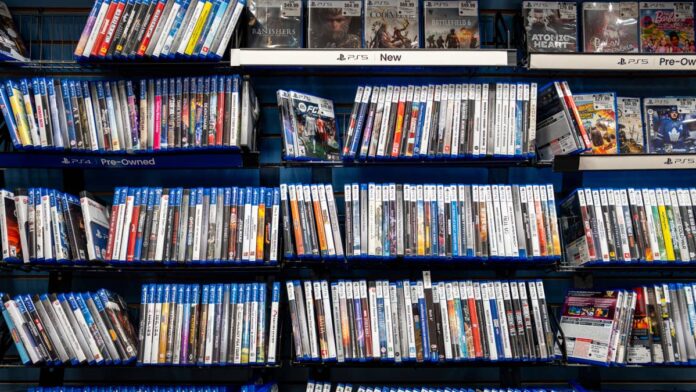 GameStop shareholders approved a routine-sounding item on Tuesday: more authorized Class A shares.The timing complicates that read. Six days earlier, <a href="https://www.thestreet.com/investing/stocks/sony-stock-playstation-discs-digital-shift">Sony confirmed</a> it will stop manufacturing physical PlayStation game discs starting in January 2028, closing the book on the exact product category GameStop was built to sell.Sony’s move wasn’t really a surprise. Nearly four in five full-game purchases on PS4 and PS5 already happen digitally, based on Sony’s own disclosures cited by <a href="https://www.thestreet.com/investing/stocks/sony-stock-playstation-discs-digital-shift">TheStreet</a>.Physical video game spending fell to <a href="https://www.thestreet.com/investing/stocks/sony-stock-playstation-discs-digital-shift">$1.5 billion in 2025</a>, the lowest total since Circana began tracking the category in 1995.<strong><a href="https://www.thestreet.com/investing/ryan-cohen-gamestop-payday-pushing-gme-ebay-deal">Related: Ryan Cohen passes on GameStop payday to keep pushing one acquisition</a></strong>GameStop has spent two years adjusting to that decline. Collectibles and trading cards made up 41.8% of first quarter revenue in fiscal 2026, up from 28.9% a year earlier, according to <a href="https://www.sec.gov/Archives/edgar/data/1326380/000132638026000020/a991-fy26q1earningsrelease.htm">a GameStop SEC filing</a>.The company also <a href="https://www.thestreet.com/retail/struggling-mall-retailer-gamestop-closes-100s-of-stores">closed 430 stores</a> across 42 states in January 2026 alone, shrinking a footprint built for a disc business that keeps shrinking with it.GameStop’s first eBay bid ran into a wallThat pivot doesn’t touch GameStop’s other big project. In May, GameStop submitted a <a href="https://www.sec.gov/Archives/edgar/data/1326380/000119312526202468/d138475dex992.htm">non-binding proposal</a> to acquire all of eBay at $125 per share in cash and stock, a 46% premium to eBay’s pre-bid price.eBay’s board rejected the offer nine days later, calling it “neither credible nor attractive” in a letter from chairman Paul Pressler, according to <a href="https://www.cnbc.com/2026/05/12/ebay-rejects-gamestops-takeover-ryan-cohen.html">CNBC</a>.The board’s stated concern was financing. GameStop’s plan leaned on roughly $9.4 billion in cash and liquid assets plus up to $20 billion in third-party financing, a structure that left several analysts unconvinced, according to <a href="https://www.cnn.com/2026/05/05/business/gamestop-ebay-analysts-nightcap">CNN</a>.GameStop kept building its position anyway. The company directly owns 4.3 million eBay shares and holds options tied to another 39 million, according to <a href="https://www.reuters.com/legal/government/gamestop-increases-stake-ebay-more-than-6-2026-05-20/">a Reuters report</a>, giving Cohen leverage regardless of whether a deal ever closes.
GameStop shareholders approved expanding authorized Class A shares to 2.5 billion, giving the retailer more currency to pursue its stalled eBay bid.<a href="https://www.gettyimages.com/detail/2274484370">Brandon Bell / Getty Images</a>
Tuesday’s vote wasn’t really about the boardAll five GameStop directors were re-elected Tuesday, and shareholders approved executive pay and the company’s auditor, according to <a href="https://seekingalpha.com/news/4612093-gamestop-gets-approval-to-expand-class-a-shares-clearing-path-for-ebay-deal?share_source=shared_news">a Seeking Alpha report</a>.Those items were never in doubt. The share count was the one that mattered.The approved amendment expands GameStop’s authorized Class A common stock to 2.5 billion shares, according to <a href="https://www.proactiveinvestors.co.uk/companies/news/1092789">Proactive</a>. That gives the company room to issue new stock as currency in an eBay deal without asking shareholders again.Final results, with the exact new share ceiling, go to the <a href="https://www.thestreet.com/dictionary/s/securities-exchange-commission">SEC</a> in a Form 8-K.The stock didn’t celebrate. GameStop (<a href="https://www.thestreet.com/quote/GME">GME</a>) closed Tuesday down 2.46% at roughly $22.20, per the Seeking Alpha report, before <a href="https://stocktwits.com/news-articles/markets/equity/gamestop-stock-rises-after-shareholders-approve-bigger-share-count-for-proposed-ebay-acquisition/cZmlDx0R7ZN">edging up</a> about 0.5% in <a href="https://www.thestreet.com/dictionary/e/extended-hours-stock-trading">after-hours</a> trading once the vote results posted.Shares slipped further in early Wednesday trading, changing hands near $22.10, according to data from <a href="https://www.thestreet.com/quote/GME">TheStreet</a>. A capital structure fix doesn’t move a stock the way a signed merger agreement would.<strong>More Retail:</strong><a href="https://www.thestreet.com/retail/60-year-old-retailer-kirklands-closes-over-240-locations-across-35-states"><strong>60-year-old retailer closes over 240 locations across 35 states</strong></a><a href="https://www.thestreet.com/retail/marshall-rousso-misura-owner-whsmith-exits-us-fashion-accounting-scandal"><strong>Retail giant exits U.S. fashion after multi-million-dollar scandal</strong></a><a href="https://www.thestreet.com/retail/hm-79-year-old-fast-fashion-retailer-closes-128-stores"><strong>79-year-old fast-fashion retailer closes 128 stores</strong></a>A retail survival plan that depends on someone else’s companyGameStop’s two stories are really one story. The disc business that funded the company for two decades is winding down on a fixed date, and collectibles alone won’t replace it at scale.The eBay bid is Ryan Cohen’s answer to that math, a bet that owning a marketplace matters more than owning shelf space.Tuesday’s vote didn’t buy eBay. It bought GameStop the paperwork to make an offer eBay’s board can’t dismiss on financing grounds alone.Whether that’s enough to get a deal done, or just extends a standoff already three months old, is the question GameStop still has to answer.<strong><a href="https://www.thestreet.com/investing/stocks/sony-stock-playstation-discs-digital-shift">Related: PlayStation is walking away from something gamers grew up on</a></strong>
