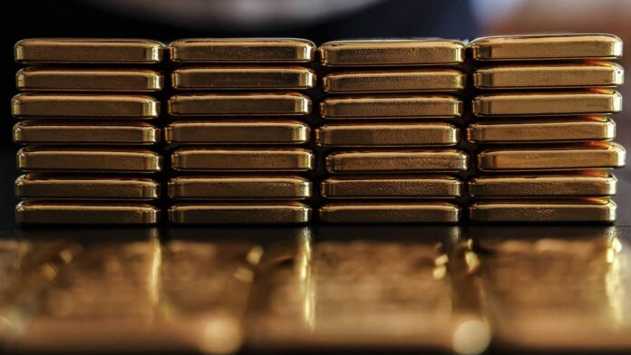 Gold climbed from about $2,600 per ounce in early 2025 to a record $5,589 by January 2026, setting more than 50 all-time highs in a single calendar year, the <a href="https://www.gold.org/goldhub/research/gold-mid-year-outlook-2026">World Gold Council</a> reported.The rally has fueled aggressive marketing by precious metals dealers, with <a href="https://www.thestreet.com/retirement">retirement</a> investors responding in record numbers.Gold exchange-traded fund holdings grew 801 tons in 2025, the second-strongest year on record, while bar and coin buying accelerated to a 12-year high, the World Gold Council reported in its<a href="https://www.gold.org/goldhub/research/gold-demand-trends/gold-demand-trends-full-year-2025"> Gold Demand Trends: Q4 and Full Year 2025 report.</a>For retirement savers considering a gold individual retirement account (<a href="https://www.thestreet.com/retirement/traditional-vs-roth-iras-which-is-right-for-your-retirement-plan">IRA</a>), the case for holding physical metal in a tax-advantaged account may seem straightforward at first glance.First-year gold IRA costs can quietly erase double-digit returnsA <a href="https://www.thestreet.com/investing/gold-iras-work-like-regular-iras-until-you-store-it-wrong">gold IRA</a> requires three service providers that a standard brokerage account does not: a custodian, a precious metals dealer, and an IRS-approved depository vault, the <a href="https://www.usmoneyreserve.com/news/executive-insights/understanding-gold-ira-fees-and-custodian-costs/">U.S. Money Reserve stated</a>.Each provider charges its own fee, with account setup running $50 to $150, annual custodian maintenance adding $75 to $300, and depository storage costing another $100 to $300.Those recurring charges, however, represent only part of the total drag on returns. The highest upfront cost is the dealer markup, the premium a dealer charges above gold's spot price, which on standard bullion typically runs 2% to 5%, <a href="https://www.irafinancial.com/blog/how-gold-ira-pricing-actually-works-spot-price-premiums-and-custodian-markups-explained/">IRA Financial reported</a>.Investors face acquisition markups ranging from 40% to 200% above spot for numismatic coins, according to a <a href="https://www.cftc.gov/LearnAndProtect/AdvisoriesAndArticles/CustomerAdvisory_COVID19PreciousMetals.htm">CFTC customer advisory</a>, and one 2024 <a href="https://www.thestreet.com/dictionary/s/securities-exchange-commission">SEC</a> enforcement action against Red Rock Secured found the firm had charged markups as high as 130% while advertising 1% to 5%. Physical gold produces zero income, while annual fees compoundUnlike dividend-paying stocks or interest-bearing bonds, gold bars and coins produce no cash flow while stored in a depository vault. Every fee charged against the account creates a direct headwind, because returns depend entirely on price appreciation over time.Annual custodian fees commonly run $75 to $300, and storage costs another $100 to $300 for flat-fee accounts, the U.S. Money Reserve confirmed. <strong>More Retirement:</strong><a href="https://www.thestreet.com/retirement/vanguard-drops-playbook-on-retirement-income"><strong>Vanguard drops playbook on retirement income</strong></a><a href="https://www.thestreet.com/retirement/vanguard-warns-workers-are-losing-thousands-in-401k-savings"><strong>Vanguard warns workers losing thousands in 401(k)s</strong></a><a href="https://www.thestreet.com/retirement/fidelitys-wake-up-call-on-social-security-iras-and-401ks"><strong>Fidelity's wake-up call on Social Security, IRAs, and 401(k)s</strong></a>Those recurring charges compound over a multi-decade holding period, working out to roughly 0.4% to 1.2% of a $50,000 balance each year before any dealer markup or transaction cost.Selling a gold IRA is often more cumbersome than many investors expect. Selling physical metal requires coordination among the custodian, dealer, and depository, a process that takes days rather than seconds.<a href="https://www.thestreet.com/retirement/fidelity-rmd-tax-torpedo-retirement">Required minimum distributions</a> further complicate matters for traditional gold IRA holders starting at age 73, because the custodian must appraise each metal holding before calculating the required annual withdrawal amount, <a href="https://www.irs.gov/retirement-plans/retirement-plan-and-ira-required-minimum-distributions-faqs">according to the IRS</a>.
Gold IRAs generate no income, while annual fees, storage costs, and liquidity challenges can steadily erode long-term retirement returns.<a href="https://www.gettyimages.com/detail/photo/stacked-gold-bullion-royalty-free-image/2270669034?phrase=Gold&searchscope=image%252Cfilm&adppopup=true">Bloomberg Creative/Getty Images</a>
Gold IRA withdrawals face ordinary income tax rates up to 37%Geoff Schmidt, a certified public accountant and founder of Holy Schmidt, <a href="https://moneywise.com/investing/retirement/gold-ira-vs-gold-etf-tax-difference-2026">told Moneywise</a> that gold ETFs and gold IRAs operate under entirely separate tax frameworks despite holding the same underlying asset."The common assumption is that a gold ETF behaves like a stock fund at tax time, with that nice 15% or 20% long-term rate. For the large physically backed funds, <a href="https://www.thestreet.com/quote/GLD">GLD</a> and <a href="https://www.thestreet.com/quote/SLV">SLV</a> being the obvious examples, it doesn't," Schmidt said.<a href="https://www.thestreet.com/investing/major-gold-etf-manager-vaneck-sets-price-target-for-2030">Gold ETFs</a> backed by physical bullion fall under <a href="https://www.thestreet.com/dictionary/i/internal-revenue-service-irs">IRS</a> collectibles rules, which cap long-term <a href="https://www.thestreet.com/dictionary/c/capital-gains">capital gains</a> at 28% rather than the standard 15%-20%, according to <a href="https://www.irs.gov/pub/irs-pdf/p550.pdf">IRS Publication 550</a>.That ceiling, however, may still be lower than what a traditional gold IRA holder pays when taking distributions. Withdrawals from a traditional gold IRA are taxed as ordinary income, Achim von Bodman, a CFP and senior tax manager at Watter CPA, told Moneywise. Under the current <a href="https://www.irs.gov/filing/federal-income-tax-rates-and-brackets">federal income tax brackets</a>, that rate can reach 37%.A <a href="https://www.thestreet.com/retirement/traditional-vs-roth-iras-which-is-right-for-your-retirement-plan">Roth IRA</a> structure is one important exception, since qualified Roth withdrawals are generally tax-free and can eliminate both the collectibles rate and ordinary income exposure altogether, Schmidt noted.Gold ETFs offer retirement exposure at a fraction of the costFor investors who want gold in a <a href="https://www.thestreet.com/personal-finance/how-much-gold-you-should-hold-in-your-retirement-portfolio">retirement portfolio</a> without the complexity of physical custody, gold exchange-traded funds held in a traditional or Roth IRA offer a streamlined, less expensive alternative.Tanza Loudenback, a Certified Financial Planner (CFP), <a href="https://smartasset.com/retirement/what-is-a-gold-ira">told SmartAsset</a> that the layered cost structure of a gold IRA rarely justifies the exposure it delivers and that investors seeking an <a href="https://www.thestreet.com/dictionary/i/inflation">inflation</a> hedge can achieve the same portfolio outcome.<blockquote>The fees associated with maintaining a gold IRA are usually not worth the potential benefits. There are other ways to get exposure to precious metals that can help counterbalance inflation, if you're worried about that, and are generally more investor-friendly, like gold ETFs</blockquote><a href="https://www.ssga.com/us/en/individual/etfs/spdr-gold-minishares-gldm">The SPDR Gold MiniShares ETF</a> has an annual <a href="https://www.thestreet.com/dictionary/e/expense-ratio">expense ratio</a> of 0.10%, and the iShares Gold Trust charges 0.25%, both far below the combined fee load of a typical gold IRA arrangement.Weighing gold IRA costs before committing retirement savingsGold's record-setting performance has earned its place in the retirement conversation, and a well-structured allocation can serve a legitimate <a href="https://www.thestreet.com/dictionary/d/diversification">diversification</a> role for long-term investors.<a href="https://www.thestreet.com/personal-finance/financial-planners-name-best-ways-to-spend-a-tax-refund">Financial planners</a> commonly cap precious metals exposure in a well-diversified portfolio at around 5%, a level that matches <a href="https://www.thestreet.com/quote/UBS">UBS</a> Wealth Management's <a href="https://www.ubs.com/global/en/wealthmanagement/insights/marketnews/article.2935563.html">mid-single-digit gold guidance</a> and the 5% gold sleeve used in Morningstar's 2026 <a href="https://www.morningstar.com/portfolios/why-portfolio-diversification-has-paid-offbut-more-isnt-always-better">Diversification Landscape</a> test portfolio.Financial planners, including Loudenback, say gold ETFs in standard retirement accounts provide similar price exposure at much lower ongoing costs.Some retirement savers continue to choose self-directed gold IRAs because they allow direct ownership of physical gold, despite the added expense.<strong><a href="https://www.thestreet.com/personal-finance/gold-iras-conceal-risks-most-investors-never-see">Related: Gold IRAs conceal risks most investors never see</a></strong>
