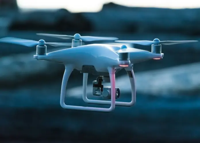 Red Cat Holdings (RCAT) is not a cheap drone stock that has been unfairly punished. It is an expensive one that has already fallen 58.5% and is still expensive. The shares closed at <strong>$7.79</strong> on July 27, 2026, up 1.96% on the day, against a 52-week range of $5.77 to $18.78 and a market capitalisation of $1.19 billion (<a href="https://stockanalysis.com/stocks/rcat/">StockAnalysis</a>). Wall Street's <a href="https://stockanalysis.com/stocks/rcat/forecast/">consensus rating is Strong Buy with a $22.00 price target</a> — 182.4% above the current price. Trailing twelve-month revenue is $54.57 million and trailing net income is <strong>negative $75.51 million</strong>. The bull case and the bear case here are not disagreements about the drone market. They are disagreements about arithmetic.
Here is the number that reframes the entire analyst debate, and I have not seen it stated anywhere else. At $7.79 with 152.19 million shares outstanding, RCAT already trades at roughly <strong>21.8 times trailing sales</strong>. The consensus $22 target implies a market capitalisation of about $3.35 billion on that same $54.57 million revenue base — <strong>61.4 times trailing sales</strong>. That is not a defence-hardware multiple; it is a pre-revenue biotech multiple. For the consensus target to be correct, Red Cat does not need to execute well. It needs revenue to multiply several times over <em>and</em> the market to keep paying a multiple that almost no hardware manufacturer in the sector sustains. Having tracked the small-cap defence complex through the 2026 drawdown, that is a far higher bar than a "Strong Buy" label communicates.
<strong>Key Facts</strong>
Share price <strong>$7.79</strong> (+1.96%), quote timestamped July 27, 2026, 4:00 PM EDT — StockAnalysis
Market capitalisation <strong>$1.19 billion</strong>; shares outstanding 152.19 million — StockAnalysis
52-week range <strong>$5.77 – $18.78</strong>: the stock sits 58.5% below its high and 35.0% above its low
Revenue (TTM) <strong>$54.57 million</strong>, up 2,282.0% year on year; net income <strong>−$75.51 million</strong>
Consensus rating Strong Buy, price target <strong>$22.00</strong> (+182.4%); street range $20 to $25 across six analysts polled by S&P Global
<strong>Needham cut its target to $12</strong> while maintaining a Buy rating — the widest gap between a bullish rating and a bearish number on the board
Implied valuation at consensus: <strong>~$3.35 billion market cap, ~61.4× trailing sales</strong> — author calculation from the figures above
Where the price actually sits
The single most useful thing an investor can do with this name is put every published number on one scale. The spread is extraordinary — the street's own low and high targets are more than twice apart, and the lowest analyst number ($12, Needham) still sits 54% above the current price.
RCAT: spot vs the 52-week range and analyst targets
Price $7.79 · quote July 27, 2026 · targets per S&P Global / Needham
52w low
$5.77
SPOT
$7.79
Needham
$12.00
52w high
$18.78
Consensus
$22.00
Street high
$25.00
−25.9% to the low
+182.4% to consensus
+220.9% to street high
Stock is 58.5% below its 52-week high. Every published analyst target sits above spot.
Two observations follow immediately. First, there is no bearish analyst on this name — the lowest published target implies a 54% gain. That unanimity is itself a risk signal, because it means sell-side estimate revisions can only travel in one direction from here. Second, the stock would have to more than double simply to reclaim its own 52-week high, a level it held before guidance was cut.
The bull case, at its strongest
The bullish argument is not frivolous, and it rests on three things that are genuinely true.
Growth is real and enormous. Trailing revenue of $54.57 million represents year-on-year growth of 2,282.0%. Fourth-quarter 2025 revenue hit a record $26.2 million, up roughly 2,000% year on year. Whatever else is true of Red Cat, it has moved from a shell-scale revenue base to a genuine operating business inside a single cycle.
The balance sheet was repaired. Cash rose to $206.4 million by the end of the third quarter of 2025 from $65.9 million the prior quarter. For a company burning cash at the current rate, that raise is the difference between a solvency question and a patience question. It buys several years of runway at present spend, which removes the most common way small-cap defence names die.
And the programme opportunity is structural. The US Army's Short Range Reconnaissance (SRR) Tranche 2 programme is a multi-year, multi-unit procurement in a category where Blue UAS-compliant, US-manufactured airframes face a deliberately narrowed field of eligible suppliers. A company that wins meaningful share of a programme like that does not grow linearly; it steps up. The bull case is that the current revenue base simply predates the step.
If SRR Tranche 2 converts at scale and gross margins normalise toward hardware-industry norms, a $22 target stops looking absurd and starts looking like a reasonable multiple on a much larger forward revenue number. That is the entire thesis, and it is coherent.
The bear case, which is mostly arithmetic
The bearish argument does not require the drone market to disappoint. It requires only that the current numbers be taken literally.
Start with gross margin. GAAP gross margin fell to <strong>4.2%</strong> from 6.6% in the prior quarter. Apply 4.2% to $54.57 million of trailing revenue and the entire top line produces roughly <strong>$2.3 million of gross profit</strong> — against a trailing net loss of $75.51 million. Put plainly: at the current margin structure, Red Cat would need revenue of roughly $1.8 billion, about 33 times what it does today, simply for gross profit to cover the present loss. Revenue growth alone does not fix this. Margin has to change, and margin is the line that just moved the wrong way.
Then the guidance. Management revised 2025 revenue guidance down to $34.5–37.5 million, approximately <strong>44% below consensus</strong>, citing a government shutdown and delays to the Edge 130 launch. Adjusted EBITDA was revised to a loss of $48.3 million. A 44% guidance miss is not a rounding error; it is a signal that the revenue line is dependent on procurement timing the company does not control.
It is worth being precise about what that dependency means in practice. Defence procurement revenue is lumpy by design: orders arrive as funded tranches tied to appropriations cycles, not as a smooth subscription curve. A company with $54.57 million of trailing revenue and a single dominant programme catalyst has, in effect, concentrated its entire forward estimate into one government decision date. When that date moves — as SRR Tranche 2 has — the revenue does not shift a quarter to the right in an orderly way. It vanishes from the modelled year entirely and reappears in the next one, which is exactly how a 44% guidance cut happens without anything going wrong operationally.
That structure also explains why the sell-side range is so wide. Analysts are not disagreeing about Red Cat's technology or its Blue UAS eligibility. They are applying different probabilities and different timing assumptions to the same binary contract event, and small changes in either input produce very large changes in a discounted forward valuation. <a href="https://finance.yahoo.com/news/needham-cuts-red-cat-holdings-145157370.html">Needham's decision to cut its target to $12 while keeping a Buy rating</a> is the clearest expression of that: the analyst still believes in the asset and has simply pushed the cash flows further out. A target cut of that size with the rating unchanged is a timing revision, not a thesis reversal — and timing is the whole argument on this name.
And the SRR catalyst has already slipped. The contract that underwrites the bull case was pushed to the first quarter of 2026. Programme delay is the specific mechanism by which the bull thesis becomes a value trap — the story stays intact, the cash keeps burning, and the multiple compresses while investors wait.
The bear case, then, is not that Red Cat fails. It is that it succeeds slowly, at 21.8 times sales, while losing more money than it earns in revenue. The net loss exceeds trailing revenue by 38.4%.
Why the rates backdrop matters more than usual here
An unprofitable company whose value sits in cash flows several years out is, in valuation terms, a long-duration asset. Its present value is unusually sensitive to the discount rate — which makes this week's Federal Reserve decision more relevant to RCAT than to a profitable industrial.
That backdrop is not favourable. Prediction markets currently price a July rate cut at just 0.30% and a hike at 25.30%, as covered in our analysis of <a href="https://financefeeds.com/fed-rate-hike-odds-25-percent-cut-priced-0-3-percent/">Fed rate hike odds at 25% against a cut priced at 0.3%</a>. The easing that would most directly support multiples on pre-profit growth names is not on the table at this meeting, and the tail risk points the other way.
This is the same dynamic visible across the small-cap space and defence complex. Our recent coverage of <a href="https://financefeeds.com/redwire-rdw-stock-24-bull-case-7-bear-case/">Redwire's $24 bull case against a $7 bear case</a> and <a href="https://financefeeds.com/intuitive-machines-lunr-stock-75-bull-case-11-bear/">Intuitive Machines' $75 versus $11 spread</a> shows the identical pattern: enormous analyst ranges, heavy losses, and valuations that depend on programme wins landing on schedule. RCAT is not an idiosyncratic story. It is a sector-wide repricing expressed through one ticker.
What would have to be true for each case
<strong>For the bull case ($22, +182.4%):</strong> SRR Tranche 2 must convert to a material, funded order in the first half of 2026. Gross margin must move from 4.2% toward double digits, which implies either manufacturing scale or a mix shift toward higher-value systems. And the market must continue paying a premium multiple through the transition — roughly 61.4 times trailing sales at the target price, which only holds if investors are underwriting a forward number far above trailing.
<strong>For the bear case ($5.77, −25.9%):</strong> Nothing dramatic needs to happen. SRR slips again, the next quarter shows gross margin flat or lower, cash burn continues near the $48.3 million adjusted EBITDA loss pace, and the stock retests its 52-week low as the growth premium compresses. Guidance has already been cut 44% once; the mechanism is proven.
The asymmetry that matters is that the bull case requires three things to go right in sequence, while the bear case requires only that the current trajectory continue.
What to watch next
Three specific markers, in order of importance.
First, the SRR Tranche 2 award and its dollar value. Not the announcement of an announcement — the funded order. This is the binary that decides which case is right, and its repeated slippage is the single best predictor of the next leg.
Second, gross margin in the next reported quarter. A print above 10% materially changes the arithmetic in this article; a print below 5% confirms that scale is not yet translating into unit economics. This is the number to check first in the release, ahead of revenue.
Third, analyst revisions. With no bearish rating outstanding and the lowest target 54% above spot, the estimate distribution is one-sided. Needham's cut to $12 while maintaining Buy is the template for how this resolves — targets fall before ratings do. A second bank following that pattern would be the clearest sell-side confirmation that the bear arithmetic is being absorbed.
My expectation is that RCAT stays range-bound between roughly $6 and $12 until SRR resolves, because neither case can be proven until the programme lands. The consensus $22 is not a forecast of the next quarter; it is a valuation of an outcome that has already been delayed once.
<em>A note on sourcing: this analysis could not verify an individually attributed, verbatim quote from a named Red Cat executive or analyst within the reporting window, so none is presented. Price and financial data are cited to StockAnalysis with a July 27, 2026 timestamp; target and guidance figures are attributed to S&P Global's analyst poll and to Needham. Valuation multiples marked as author calculations are derived from those figures and shown with their inputs. Nothing here is investment advice.</em>
FAQ
<strong>What is the price target for RCAT stock?</strong>
The consensus target is $22.00, implying 182.4% upside from $7.79. Six analysts polled by S&P Global give a range of $20 to $25, with a Strong Buy consensus rating. Needham separately cut its target to $12 while maintaining a Buy rating.
<strong>Why has Red Cat stock fallen so far?</strong>
The shares sit 58.5% below their 52-week high of $18.78. The proximate cause was a 2025 revenue guidance cut to $34.5–37.5 million, roughly 44% below consensus, attributed to a government shutdown and delays to the Edge 130 launch, alongside gross margin falling to 4.2%.
<strong>Is RCAT profitable?</strong>
No. Trailing twelve-month net income is −$75.51 million on revenue of $54.57 million, meaning the net loss exceeds revenue by 38.4%. Adjusted EBITDA was revised to a loss of $48.3 million. Cash stood at $206.4 million at the end of the third quarter of 2025, which funds the burn but does not resolve it.
<strong>What is the Army SRR Tranche 2 programme?</strong>
Short Range Reconnaissance Tranche 2 is a US Army procurement for small reconnaissance drones, restricted to compliant US-manufactured suppliers. It is the central catalyst in the bull case for Red Cat. The contract has slipped to the first quarter of 2026, and that delay is the primary reason the stock de-rated.
<strong>Is RCAT expensive at $7.79?</strong>
On trailing figures, yes. A $1.19 billion market capitalisation on $54.57 million of revenue is approximately 21.8 times sales. At the $22 consensus target the implied market capitalisation is about $3.35 billion, or roughly 61.4 times trailing sales — a multiple that requires substantial forward revenue growth to justify.
<strong>What would change the bear case?</strong>
A funded SRR Tranche 2 order with a disclosed dollar value, combined with gross margin moving above 10% in a reported quarter. Those two together would shift the debate from whether the unit economics work to how fast revenue scales, which is the ground the bulls want to fight on.