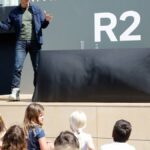 Tesla rival trims spending plans despite revenue beat