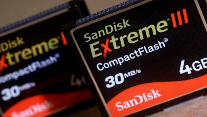 I have been tracking SanDisk's numbers. It’s one of my favourites. Why? Its performance, and the reason behind the big numbers. And the numbers keep doing something unusual for sure. They keep getting bigger than the already-big numbers that preceded them.If you didn’t know, SanDisk (SNDK) is the top-performing <a href="https://www.thestreet.com/dictionary/s/s-p-500">S&P 500</a> stock in 2026, up 707.11% year-to-date, according to <a href="https://www.slickcharts.com/sp500/performance">SlickCharts</a>. It has lapped Micron almost three times. It has lapped Dell, which sits in second position. It has lapped everything. It has honestly been incredible.And on July 5, Goldman Sachs did something that made even veteran semiconductor watchers stop and look twice. Goldman nearly doubled its SanDisk price target, maintaining its Buy rating in a note shared with me at TheStreet.The 38-year-old SNDK closed July 9 at $1,858.27, up 7.59% on the session, according to <a href="https://finance.yahoo.com/quote/SNDK/">Yahoo Finance</a>. The new target, around $2,200, implies roughly 18% further upside from that close.But the number itself is almost secondary to what Goldman is actually saying. The firm's non-GAAP <a href="https://www.thestreet.com/dictionary/e/earnings-per-share-eps">earnings per share</a> estimate for calendar year 2026 is more than 30% above the Street consensus, as noted. That gap between Goldman's view and the market's is the real story here. Let’s look at it.<a href="https://www.thestreet.com/quote/SNDK"><strong>Also Read: SanDisk Corp. Latest News and Stories</strong></a>What Goldman is seeing that most analysts are not On July 9, I covered Goldman's <a href="https://www.thestreet.com/investing/stocks/advanced-micro-devices-amd-stock-goldman-server-cpu-demand-earnings-july-2026">AMD earnings preview</a> from the same source, noting that the server CPU story wins the earnings. My colleague broke down <a href="https://www.thestreet.com/investing/stocks/goldman-sachs-keeps-applied-materials-buy-rating">AMAT</a>, citing expected DRAM strength to drive best-in-class growth in 2026. Today, it is SanDisk's turn, and the setup Goldman describes is even more bullish.The firm raised its 12-month target to $2,200 from $1,200, based on a 20 times price-to-earnings multiple applied to a normalized EPS estimate of $110, significantly higher than the prior estimate of $55, Goldman wrote in the note shared with me.<blockquote>We expect a very strong quarter driven by continued NAND supply tightness.</blockquote><strong>More SanDisk:</strong><a href="https://www.thestreet.com/investing/stocks/sandisk-long-term-contracts-memory-stock"><strong>Bernstein’s SanDisk forecast reboot sparks massive target upgrade</strong></a><a href="https://www.thestreet.com/investing/stocks/sndk-sandisk-sarge-guilfoyle-raises-stock-price-target"><strong>Veteran Wall Street trader sharply raises SanDisk stock price target</strong></a><a href="https://www.thestreet.com/investing/stocks/sndk-sandisk-morgan-stanley-maintains-overweight-ai-demand-drives-nand-fundamental-repricing"><strong>Sandisk future hinges on powerful AI shift, says Morgan Stanley</strong></a>The target methodology is worth reading carefully. Goldman reduced its multiple from 22 times to 20 times on a higher earnings base, and the EPS estimate doubled. That is not a valuation <a href="https://www.thestreet.com/dictionary/i/inflation">inflation</a> story. It is a fundamental earnings power revision driven by NAND pricing data that Goldman believes the Street has not yet fully incorporated.The firm expects SanDisk to deliver significant upside to <a href="https://investor.sandisk.com/news-releases/news-release-details/sandisk-report-fiscal-fourth-quarter-and-fiscal-year-2026">fourth quarter results </a>and guidance when it reports on August 5, with additional investor attention on long-term agreements and NAND pricing commentary following Micron's strong results. Goldman specifically noted that positioning heading into the print appears bullish given "extremely strong Q2 guidance" and positive management commentary in recent weeks.My read of that setup is that Goldman is essentially saying the quarter will be strong, the guidance will be strong, and the LTA disclosures could be the catalyst that forces a broader re-rating.Here’s the NAND supply story Goldman is betting onGoldman sees tight supply-and-demand conditions in NAND persisting longer than in DRAM, driven by limited supply additions across the industry, according to the note. SanDisk is simultaneously improving its product mix through ramping eSSD design wins at key hyperscaler customers. More than one-third of fiscal year 2027 bit output is already committed under New Business Model agreements.<strong><a href="https://www.thestreet.com/investing/stocks/bank-of-america-revamps-sandisk-stock-price-target">Related: Bank of America revamps Sandisk stock price target</a></strong>The LTA disclosure story is the item Goldman flagged most specifically as a potential stock mover on the August 5 call. Following the number of new agreements recently announced by Micron, Goldman said the scope and number of new LTA disclosures from SanDisk will be a key focal point for investors.Each new hyperscaler commitment locks in pricing and volume, removing the cyclical pricing risk that has historically capped memory stock multiples.Goldman also acknowledged a few downside hazards. A structural change in NAND pricing failing to materialize, Chinese competitor <a href="https://www.ymtc.com/en/">YMTC</a> iterating on its roadmap, and SanDisk failing to gain eSSD traction. But the firm's conviction is that none of those risks are imminent, and that supply remains structurally constrained well into 2027.
SanDisk (SNDK) is the top-performing S&P 500 stock in 2026, up 707.11% year-to-date, as of this reporting.<a href="https://www.gettyimages.com/detail/news-photo/sandisk-corp-compactflash-digital-memory-cards-are-arranged-news-photo/94873173?adppopup=true">Jin Lee/Bloomberg via Getty Images</a>
SanDisk's Q3 results and Q4 guidance frame what August 5 needs to deliverThe<a href="https://www.sandisk.com/company/newsroom/press-releases/2026/2026-04-30-sandisk-reports-fiscal-third-quarter-2026-financial-results"> Q3 fiscal 2026</a> results, reported on April 30, set the financial foundation that Goldman is building on.Revenue of $5.95 billion, up 97% above Q2 sequentially and 251% above the year-ago quarterDatacenter revenue grew 645% year over year, and 233% quarter over quarterGAAP net income was $3.615 billion, up 287% year over year, with a non-GAAP EPS of $23.41. Five New Business Model agreements were signed during and immediately after the quarter.For Q4 fiscal 2026, SanDisk anticipated revenue of $7.75 billion to $8.25 billion and non-GAAP EPS of $30.00 to $33.00. That guidance range, at the midpoint, would represent another massive sequential step from an already historic Q3.<blockquote>This quarter marks a fundamental inflection point for SanDisk.</blockquote>Continued CEO David Goeckeler in the Q3 earnings release, "We are advancing to a new business model built on multi-year customer engagements backed by firm financial commitments. This transformation is driving structurally higher and more durable earnings power."July 10, 2026, <a href="https://advantage.factset.com/hubfs/Website/Resources%20Section/Research%20Desk/Earnings%20Insight/EarningsInsight_071026.pdf">FactSet</a> data confirms that SanDisk is among the largest contributors to Information Technology (IT) sector earnings growth since March 31, alongside Micron, <a href="https://www.thestreet.com/quote/NVDA">Nvidia</a>, and Apple.<strong><a href="https://www.thestreet.com/investing/stocks/goldman-sachs-keeps-applied-materials-buy-rating">Related: Goldman Sachs doubles down on Applied Materials stock target</a></strong>The semiconductor sector is expected to report 131% year-over-year earnings growth in Q2, and SanDisk is one of the primary engines of that growth. Excluding the industry, the estimated earnings growth rate for the IT sector would fall to 25.8% from 63.3%.SanDisk's <a href="https://investor.sandisk.com/news-releases/news-release-details/sandisk-report-fiscal-fourth-quarter-and-fiscal-year-2026">investor day</a> on August 13 follows just eight days after earnings, providing another near-term catalyst window for management to quantify the multi-year LTA pipeline and long-term financial targets.Remember, SNDK has already returned 707% year-to-date, a $2,200 Goldman target, and an EPS estimate 30% above consensus. To me, that means the move is not over. August 5 will tell us whether everybody else is ready to agree.<strong><a href="https://www.thestreet.com/real-estate/goldman-sachs-major-prediction-us-housing-market">Related: Goldman Sachs issues major prediction for US housing market</a></strong>