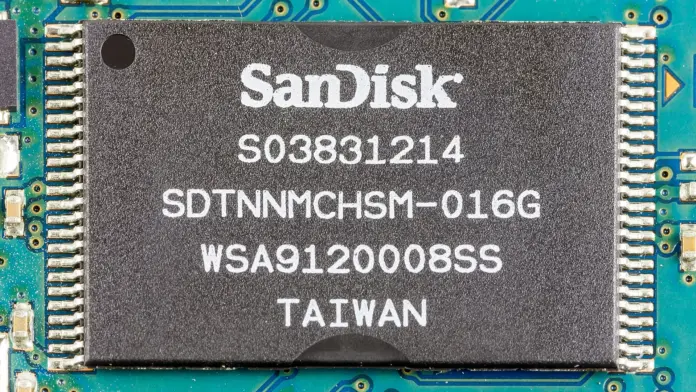 A SanDisk (SNDK) stock price prediction that opens with "the shares are up nineteen-fold, so they must be expensive" has already mispriced the question. At Friday's close of $1,791.82 the stock changed hands at roughly ten times the annualised earnings SanDisk itself guided to for the September quarter. Boom multiples do not look like that. Discount multiples do. The market is not paying up for this memory cycle; it is declining to capitalise it, and the distance between those two readings is where the whole argument lives. Having followed NAND contract pricing through the 2018 and 2022 unwinds, the number that decides these cycles is never the size of the move. It is which half of the revenue line produced it.
Two figures set the shape. SanDisk finished Friday 19 times above its 52-week low of $93.53 and still 23.9% below its 52-week high of $2,354.39. Inside that same twelve months sits a 56.5% drawdown, from a $2,335 closing peak on 25 June 2026 to $1,015.89 on 29 July. That is not the profile of a stock being accumulated. It is the profile of a stock being rented. The reason is in SanDisk's own filing rather than in any broker note: the company told the SEC that sequential revenue growth in the June quarter came "approximately one-third from higher volumes and two-thirds from higher pricing". Two thirds of the improvement was average selling price, and ASP is the one input in this industry that has never held a level for more than a handful of quarters.
Key facts
SanDisk closed at <strong>$1,791.82</strong> on Friday 18 September 2026, up 10.99% on the session, with after-hours trade at $1,798.00 — <a href="https://stockanalysis.com/stocks/sndk/">stockanalysis.com, 18 September 2026</a>
Market capitalisation <strong>$262.36bn</strong>; the one-year sell-side consensus target is <strong>$2,200.00</strong>, 22.8% above the tape — <a href="https://www.nasdaq.com/market-activity/stocks/sndk">Nasdaq, 18 September 2026</a>
Fiscal Q4 2026 revenue was <strong>$8.97bn</strong>, up 51% sequentially and 372% year on year, at an 84.6% GAAP gross margin — <a href="https://www.sec.gov/Archives/edgar/data/2023554/000162828026053346/sndkq4-26ex991xpressrelease.htm">SEC Form 8-K, Item 2.02, 5 August 2026</a>
Guidance for fiscal Q1 2027 is revenue of <strong>$10.30bn to $10.80bn</strong> and non-GAAP diluted EPS of <strong>$44.00 to $46.00</strong> on about 155m diluted shares — <a href="https://www.sec.gov/Archives/edgar/data/2023554/000162828026053346/sndkq4-26ex991xpressrelease.htm">SEC Form 8-K, 5 August 2026</a>
NAND flash contract prices are forecast to rise <strong>10–15% quarter on quarter</strong> in 3Q26, "a noticeably slower pace than in previous quarters" — <a href="https://www.trendforce.com/presscenter/news/20260703-13134.html">TrendForce, 3 July 2026</a>
SanDisk holds a <strong>49.9%</strong> interest in each of the three Flash Ventures joint ventures with Kioxia, spanning eight Japanese fabs; its top ten customers accounted for <strong>44%</strong> of fiscal 2026 net revenue — <a href="https://www.sec.gov/Archives/edgar/data/2023554/000162828026057406/sndk-20260703.htm">SEC Form 10-K, 17 August 2026</a>
S&P Dow Jones Indices confirmed on 4 September that SanDisk joins the S&P 100 before the open on Monday 21 September — <a href="https://press.spglobal.com/2026-09-04-Bloom-Energy,-Illumina,-and-Everpure-Set-to-Join-S-P-500-Others-to-Join-S-P-100,-S-P-MidCap-400,-and-S-P-SmallCap-600">S&P Dow Jones Indices, 4 September 2026</a>
Friday's 11% was a calendar event wearing a fundamental costume
The first job of any honest SanDisk (SNDK) stock price prediction this weekend is to explain the 10.99% move that produced the price it is built on. SanDisk traded 17.79m shares against a 13.87m average, and closed at the high end of a $1,616.00 to $1,797.00 range after opening at $1,625.20.
There is no company disclosure behind it. SanDisk filed nothing with the SEC on 17 or 18 September. Its two most recent current reports are administrative: an 11 September filing covering a refinanced revolving credit facility, and a 16 September filing recording compensation adjustments for its chief technology officer and chief legal officer. Neither is a trading catalyst.
What does sit on the calendar is an index change. S&P Dow Jones Indices announced on 4 September that SanDisk, Dell Technologies, Palo Alto Networks and Arista Networks would enter the S&P 100 before the open on Monday 21 September, displacing Nike, Honeywell Aerospace, Simon Property Group and Colgate-Palmolive. Friday was the last regular session before that change, which is precisely when index-tracking money has to be done, and the closing auction is where it gets done.
That explains the mechanism. It does not explain the magnitude. The S&P 100 is a small pool of tracked assets set against a $262bn company, and the rest of the storage complex moved in the same direction on the same day without any index event of its own: Seagate closed up 6.93% at $858.79, Western Digital up 4.13% at $441.36, Micron up 3.92% at $1,015.80. Nvidia, the usual proxy for AI enthusiasm, added 1.34%. The bid was storage-specific, SanDisk led it by roughly four percentage points over the next-best name, and a rebalance deadline sat underneath. Anyone selling you a single clean fundamental reason for Friday is guessing. The honest read is flow meeting an already-tight tape, which is also the read that applies to the <a href="https://financefeeds.com/western-digital-wdc-stock-prediction-725-bull-290-bear/">Western Digital bull and bear case</a> trading alongside it.
The company's own framing of the year is deliberately unspectacular. "We closed fiscal 2026 with a leading technology portfolio, established datacenter as a key growth pillar, and deepened our customer partnerships," said David Goeckeler, Chairman and Chief Executive Officer of SanDisk, in the results release filed with the SEC on 5 August 2026. Nothing in that sentence promises the price holds.
The industry is quietly trying to stop selling at spot
What SanDisk has actually done with the windfall is more informative than what it has said about it. The board expanded the share repurchase authorisation by $14bn in August, taking the remaining authorisation to $15.5bn — about 5.9% of the current market value. On 9 September the company amended its loan agreement with JPMorgan Chase as administrative agent, refinancing its revolving commitments in full into a new $1.5bn facility priced at SOFR plus 1.375%. Neither move is the behaviour of a management team that thinks the earnings are permanent; both are the behaviour of one converting a cash spike into optionality.
The strategic move is quieter and matters more. SanDisk disclosed that since announcing five New Business Model agreements on its April earnings call it has signed five additional ones, including three with new customers and two that expand existing deals. Ten contracts, in a business that historically sold into quarterly contract negotiations.
Micron is doing the same thing under a different name. In its fiscal third-quarter release filed with the SEC on 24 June 2026, the company reported revenue of $41.46bn and GAAP earnings of $24.67 per diluted share, and framed the strategy explicitly. "We believe our multi-year Strategic Customer Agreements will significantly enhance the durability and predictability of Micron's strong financial performance," said Sanjay Mehrotra, Chairman, President and Chief Executive Officer of Micron Technology.
Put those two disclosures side by side and an insight falls out that neither company states on its own. The two largest sellers of memory bits in the Western market are simultaneously racing to convert spot-exposed average selling prices into contracted, multi-year revenue. Suppliers do not do that at the bottom of a pricing cycle. They do it when they suspect the current price is better than the price they will be able to get later, and they would rather lock a lower durable number than defend a higher fragile one. That is management's revealed view of the ASP curve, and it is considerably more sober than the sell-side targets attached to either name. The same tension runs through the <a href="https://financefeeds.com/micron-mu-stock-prediction-1500-bull-560-bear/">Micron bull and bear case</a>.
Ten times earnings, on both sides of the memory trade
SanDisk (SNDK) daily closes to 18 September 2026 on a log price axis, with the $2,520 bull, $1,980 base and $1,240 bear levels marked. A linear axis would compress the first six months of the move into the baseline. Data: stockanalysis.com. Chart: FinanceFeeds.
Take the midpoint of SanDisk's own September-quarter guidance, $45.00 of non-GAAP diluted EPS, and annualise it. That is $180.00 against a $1,791.82 share price: 9.95 times. Run the identical arithmetic on Micron's reported June-quarter non-GAAP EPS of $25.11 and you get $100.44 annualised against a $1,015.80 close, or 10.11 times. Two different companies, two different fiscal calendars, one multiple.
Friday 18 September 2026CloseOne-day change
SanDisk (SNDK)$1,791.82+10.99%
Seagate (STX)$858.79+6.93%
Western Digital (WDC)$441.36+4.13%
Micron (MU)$1,015.80+3.92%
Nvidia (NVDA)$222.27+1.34%
Regular-session closes pulled from stockanalysis.com on 19 September 2026.
A single-digit-to-ten multiple applied independently to two unrelated issuers is not a company judgement. It is a cycle judgement. The market has decided roughly what fraction of today's memory earnings it believes survives, and it has priced both names to the same answer.
Now combine SanDisk's guidance with an outside pricing forecast, because the interaction says something neither source does. TrendForce, on 3 July 2026, put NAND flash contract price increases at 10–15% quarter on quarter for 3Q26, explicitly slower than prior quarters, with conventional DRAM at 13–18%. SanDisk's fiscal first quarter of 2027 covers almost exactly that calendar window, and its guided revenue midpoint of $10.55bn is 17.7% above the $8.97bn it just delivered. Subtract a 12.5% midpoint price contribution and roughly five percentage points of the guided sequential growth has to come from bits and mix rather than price. That is a reversal of the June quarter's two-thirds-price split, and it is the single most bullish disclosed data point in the file. The price ceiling FinanceFeeds examined in the <a href="https://financefeeds.com/kioxia-nand-price-ceiling-70-percent-sk-hynix/">Kioxia contract pricing analysis</a> is beginning to bind; volume is taking over the baton. Whether it can carry the weight is the whole bull case.
Three joint ventures, eight fabs, one country
The structural risk in SanDisk is not demand. It is the fact that the company does not own its manufacturing base.
Its fiscal 2026 annual report describes three joint ventures with Kioxia — Flash Partners, Flash Alliance and Flash Forward, collectively Flash Ventures — running across eight flash manufacturing facilities in Japan, six at Yokkaichi and two at Kitakami. SanDisk holds a 49.9% ownership position in each entity, jointly controls operations with Kioxia, and Kioxia owns the buildings and supplies the wafer manufacturing services. The arrangement lowers unit cost. It also means SanDisk cannot unilaterally add capacity when prices are high or withhold it when they are falling, which is the practical limit on the supply discipline that every memory bull case assumes.
Geographic concentration compounds it. Every wafer in that structure comes out of two Japanese prefectures. Trade policy aimed at semiconductor equipment or advanced memory, whether administered by the US Bureau of Industry and Security or by Japan's Ministry of Economy, Trade and Industry, lands on a single-country footprint with no second source. SanDisk's own risk disclosure names evolving trade policies, tariff regimes and fluctuations in average selling prices in the same breath.
Customer concentration is drifting the wrong way at the same time. The 10-K reports that the top ten customers accounted for 44% of fiscal 2026 net revenue, against 40% in fiscal 2025 and 41% in fiscal 2024, with no single customer above 10%. That climb tracks the datacentre mix shift precisely: the Datacenter segment produced $5.15bn of fiscal 2026 revenue, up 437%, and reached 33.2% of the June quarter alone. Selling more bits to fewer, larger buyers raises the margin and raises the fragility together. The China supply question examined in the <a href="https://financefeeds.com/cxmt-25-percent-hbm3-yield-ymtc-14-percent-nand-2027-memory-gap/">CXMT and YMTC yield analysis</a> is the medium-term variable nobody on either side of this trade can model with confidence.
The call: $2,520 bull, $1,980 base, $1,240 bear
Every level below is a multiple applied to an earnings number, not a chart pattern. The anchor is $180.00 of annualised non-GAAP EPS, four times the $45.00 midpoint of SanDisk's own September-quarter guidance.
<strong>Base case, $1,980 — 45% probability.</strong> Eleven times the guided run-rate, 10.5% above Friday's close. This assumes NAND contract pricing decelerates as TrendForce expects without reversing, that bits carry the growth SanDisk has guided to, and that the market keeps refusing to award a durability premium. It is the outcome where nothing much changes and the multiple simply holds.
<strong>Bull case, $2,520 — 30% probability.</strong> Fourteen times the same $180.00, 40.6% above the tape and 7% above the 52-week high. This requires the ten New Business Model agreements to visibly smooth the revenue line across two consecutive quarters, which is the only evidence that would justify re-rating memory earnings toward the multiple applied to contracted semiconductor businesses. It is a re-rating case, not a beat-the-number case.
<strong>Bear case, $1,240 — 25% probability.</strong> Ten times a normalised $124.00, which is quarterly EPS falling 31% from the guided $45.00 to $31.00 as average selling prices give back part of a move that carried SanDisk's quarterly GAAP gross margin from 26.2% to 84.6% in a single year. That is 30.8% below Friday's close and still 22% above the $1,015.89 low printed on 29 July. Note what the bear case does not require: no demand collapse, no share loss, no balance-sheet event. It requires only that price behaves the way price has behaved in every previous memory cycle.
Supports the bullSupports the bear
Guided bit-driven growth in fiscal Q1 2027 breaks the price-only patternTwo thirds of June-quarter sequential growth was price, not volume
Ten New Business Model contracts signed since April84.6% gross margin is a cycle peak, not a structural moat
Datacenter revenue up 437% in fiscal 2026Top ten customers now 44% of revenue and rising
$15.5bn of buyback authorisation remaining49.9% JV stake means no unilateral control of supply
The invalidation levels are explicit. A weekly close above $2,335, the highest close of the past twelve months, retires the bear case in its current form. A weekly close below $1,015.89 retires the base case. What would change this view fastest is the fiscal Q1 2027 revenue split: if SanDisk again reports that most of its sequential growth came from pricing rather than bits, the bull case loses its only load-bearing evidence and the probabilities move toward the bear. The <a href="https://financefeeds.com/ddr5-prices-are-up-nearly-500-as-hyperscalers-book-2027-supply/">hyperscaler pre-buying of 2027 supply</a> is the other variable worth tracking, because forward booking pulls demand out of future quarters as reliably as it supports present ones.
Frequently asked questions
What is the SanDisk stock price forecast for the next twelve months?
This SanDisk (SNDK) stock price prediction sets a base case of $1,980, a bull case of $2,520 and a bear case of $1,240 against a Friday close of $1,791.82, with probabilities of 45%, 30% and 25% respectively. Each level is a multiple of $180.00 in annualised non-GAAP earnings, derived from the midpoint of SanDisk's own fiscal Q1 2027 guidance filed with the SEC on 5 August 2026.
Why is SanDisk stock up nineteen times in a year?
Because NAND flash average selling prices repriced violently. SanDisk's fiscal 2026 revenue rose 175% to $20.25bn and its gross margin went from 30.1% to 71.5%. The company attributed roughly two thirds of its June-quarter sequential growth to higher pricing and one third to higher volumes, which is why the equity behaves like a geared claim on contract NAND prices rather than a technology multiple.
Is SanDisk expensive at $1,791.82?
On trailing fiscal 2026 non-GAAP earnings of $70.88 per share the stock trades at 25.3 times. On the annualised midpoint of its own forward guidance it trades at 9.95 times. The gap between those two figures is the entire debate: whichever number turns out to be the right denominator determines whether the shares are cheap or merely early in a mean reversion.
What happened to SanDisk stock on 18 September 2026?
The shares rose 10.99% to $1,791.82 on 17.79m shares against a 13.87m average. SanDisk filed no 8-K on 17 or 18 September, so no company disclosure accounts for it. The stock enters the S&P 100 before the open on Monday 21 September, making Friday the last session for index-tracking funds to complete the trade, and the wider storage complex rose with it.
How exposed is SanDisk to Kioxia?
Substantially. SanDisk holds 49.9% of each of the three Flash Ventures joint ventures and shares control with Kioxia across eight Japanese fabs, six in Yokkaichi and two in Kitakami. Kioxia owns the facilities and provides the wafer manufacturing services. SanDisk therefore cannot independently expand or curtail its own supply, which constrains both its upside in a shortage and its defence in a glut.
Does SanDisk pay a dividend?
No. Nasdaq lists no annualised dividend and no ex-dividend date for SNDK as of 18 September 2026. Capital is being returned through repurchases instead, with $15.5bn of authorisation remaining after the board added $14bn in August 2026.
<em>This article is analysis and general information, not investment advice. It reflects the author's reading of primary filings and market data as of Friday 18 September 2026 and makes no recommendation to transact in any security. Equity markets carry risk and capital is at risk. Figures may be superseded by subsequent disclosures.</em>