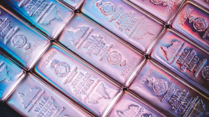Silver's slide to the $58 area is being read as the end of the 2026 precious-metals story — and that reading gets the causality backwards. The metal fell more than 2% on July 8 after the US–Iran interim peace framework collapsed, extending a retreat from December's record above $83, yet the physical market underneath has tightened rather than loosened: Shanghai Futures Exchange warehouse inventories have collapsed 86% from their 2020 peak to 715 tonnes, the lowest since July 2016 (<a href="https://www.ebc.com/forex/silver-supply-deficit-explained-why-tight-inventories-could-still-squeeze-prices-in-2026">EBC Financial Group</a>, July 2026). Wall Street's targets frame the argument: Commerzbank sees $90 by year-end and Bank of America concedes a spike above $100 is possible, while the chart's bearish triangle points at $57.50 and the year-to-date low of $55.60 sits just below (<a href="https://www.fxleaders.com/news/2026/07/08/silver-price-forecast-bearish-triangle-breakdown-locks-target-near-57-50-as-post-treaty-carry-costs-intensify/">FX Leaders</a>, July 8, 2026). This silver price prediction maps the $90 bull case, the $55 bear case, and the single dispute that decides between them.
That dispute is not geopolitics — it is the most consequential forecasting disagreement in commodities right now, and almost no coverage puts the two numbers side by side. In April, the Silver Institute and Metals Focus projected the market's sixth consecutive structural deficit would *widen* 15% in 2026, to 46.3 million ounces from 40.3 million. Six weeks later, Bank of America's metals team argued the same deficit could *shrink by 90%* this year as solar manufacturers engineer silver out of their products. Both cannot be right, and every price target above — from $100 spikes to a $55 washout — is downstream of which deficit model you believe. Having tracked the metal across three rails this year (COMEX futures, London OTC and the always-open crypto-wrapped layer), the honest answer is that the physical inventories currently side with the Institute, while the substitution pipeline sides with BofA on a 2027 fuse.
<strong>Key Facts:</strong>
<blockquote>
• Silver trades near $58.40 after a 2%+ drop on July 8, down from a December 2025 record above $83 — <a href="https://tradingeconomics.com/commodity/silver">TradingEconomics</a>
• The Silver Institute and Metals Focus project a sixth consecutive deficit year, widening 15% to 46.3 million ounces in 2026 — Silver Institute annual outlook, April 15, 2026
• Bank of America counters that "the silver deficit could decline by 90% this year" on solar thrifting — Michael Widmer, BofA, May 29, 2026
• Shanghai Futures Exchange silver inventories have fallen 86% from the 2020 peak to 715 tonnes, a nine-year low — EBC Financial Group
• Bank targets span $60–65 (JPMorgan average), $68–74 (ING), ~$69 (BMO), $90 year-end (Commerzbank), with BofA allowing a $100+ spike — bank research, May–July 2026
• Technical picture: bearish triangle targeting $57.50, with the $55.60 year-to-date low as final support — FX Leaders, July 8, 2026
</blockquote>
What's actually happening: a haven unwind masking a supply story
Silver's 2026 round trip has been violent even by its own standards. The metal rode the Gulf conflict and the Fed-pivot trade to a record above $83 in December 2025, held $70 as recently as June 15, then gave up the entire war premium in eleven sessions when the US–Iran ceasefire landed — a move we tracked in real time in our <a href="https://financefeeds.com/silver-price-forecast-2026-year-end/">silver year-end forecast</a>. July's escalation reversed the politics but not the price: this week's collapse of the interim peace framework knocked silver lower still, because the metal's industrial half now outweighs its haven half whenever risk assets wobble.
The mechanism matters for what comes next. Roughly 70% of mine supply arrives as a byproduct of copper, zinc, lead and gold operations, which is why six years of deficits have produced so little supply response — byproduct miners do not add capacity because the silver credit improved. Demand, meanwhile, is dominated by industry (solar photovoltaics above all), which is exactly where the substitution battle is being fought. JPMorgan's Gregory Shearer, head of base and precious metals strategy, sees prices averaging $60–65 through the rest of the year and frames the real risk explicitly.
"Long term, the largest risk we see for silver comes from more widespread adoption of silver-free technology, such as the cadmium telluride thin-film technology. We've already seen some of the larger solar panel manufacturers in China announce thrifting plans... So we do think that this price rally has already set in motion an acceleration in substitution trends," Shearer said (<a href="https://finance.yahoo.com/news/silver-price-predictions-why-jpmorgan-123001668.html">Yahoo Finance</a>).
<strong>Quick Take:</strong> The war premium came and went; the deficit didn't. Silver at $58 is an industrial-substitution debate wearing a geopolitical costume.
The industry response: banks split, warehouses empty, refiners hedge
The institutional map has rarely been this polarised. Commerzbank holds the high ground at $90 by end-2026 and $95 by end-2027. ING ($68–74) and BMO (~$69) cluster in the middle. JPMorgan's $60–65 average is the working bear among the bulge bracket — and the substitution logic behind it is corroborated from the bullish side, since Bank of America's Michael Widmer makes the same observation with a harder number: "As silver prices rose almost exponentially, market participants such as solar PV manufacturers faced immense margin pressure, incentivizing efforts to engineer silver out of industrial products," he wrote, concluding that "the deficit in 2026 is expected to be so small that even modest investor sales would be enough to flip the market into a surplus" (<a href="https://finance.yahoo.com/markets/commodities/articles/bank-america-stark-message-silver-154038166.html">Yahoo Finance</a>, May 29, 2026).
Against that stands the physical evidence. SHFE warehouse stocks at 715 tonnes are not a forecast — they are what remains after two years of Chinese industrial drawdown, and COMEX registered coverage ratios near 13% tell the same story on the US side, a structural fragility we examined when <a href="https://financefeeds.com/silver-price-breaks-above-80-for-the-first-time-why-this-could-signal-a-bearish-turn/">silver first broke $80</a>. The market's plumbing — refiners quoting extended delivery times, lease rates spiking on borrow demand — behaves like the Institute's 46.3-million-ounce deficit, not like BofA's near-surplus. Someone's model is mis-specified, and the divergence itself is tradable information.
Market impact and the numbers: $90 bull vs $55 bear
The scenario map falls directly out of the deficit debate, with the technicals supplying the levels.
ScenarioTargetWhat has to happenKey evidence forKey evidence against
<strong>Bull — $90</strong>$90 by end-2026 (Commerzbank); BofA allows a $100+ spikeThe Institute's deficit model proves right; SHFE/COMEX inventory stress forces restocking; gold's Warsh-pivot bid spills overSix consecutive deficit years; SHFE stocks at nine-year lows; 70% byproduct supply can't respond to priceThrifting is already visible in Chinese solar bids; the haven bid now cuts against silver in risk-off weeks
<strong>Base — $65–74</strong>ING/BMO/JPM clusterDeficit narrows but doesn't flip; price grinds with gold's directionWidest bank cluster; matches JPM's $60–65 average with Q4 seasonalityRarely do polarised markets settle at consensus mid-points
<strong>Bear — $55</strong>$57.50 triangle target, then the $55.60 YTD lowBofA's 90% deficit collapse materialises; ETF and retail length liquidates into a surplus marketPost-treaty carry costs biting; bearish triangle already broken per FX Leaders; substitution acceleratingSpot inventories at multi-year lows make a true surplus hard to deliver into
<em>Sources: Commerzbank, BofA, ING, BMO, JPMorgan research (May–July 2026); Silver Institute/Metals Focus April 2026 outlook; FX Leaders technical analysis, July 8, 2026.</em>
The synthesis worth pricing: deficits are stocks-and-flows arguments, and the two sides are talking about different years. The Institute's 46.3-million-ounce 2026 shortfall is measured against demand already contracted; BofA's near-surplus is a statement about the *next* design cycle of solar panels, which takes 12–18 months to flow through fabrication lines. Both can be sequentially true — deficit now, surplus later — which is precisely the configuration that produced 2025's blow-off top and 2026's retracement. It also mirrors the pattern we flagged in our earlier <a href="https://financefeeds.com/silver-xag-price-prediction-2026-85-base-106-bull-55-bear/">silver $85 base / $106 bull / $55 bear scenario work</a>: the physical squeeze sets the highs, the substitution response sets the lows, and the price spends most of its time overshooting between them.
Two secondary reads support the sequencing thesis. First, positioning: the retail squeeze community that powered earlier episodes remains engaged — r/SilverSqueeze and r/Silverbugs are still among the most active commodity forums on Reddit this month — but engagement metrics are a fraction of the December mania, which means the speculative froth that needed flushing has largely been flushed. Second, the gold ratio: silver's underperformance since June has pushed the gold-silver ratio sharply higher at precisely the moment gold's central-bank bid (the Warsh-pivot trade) remains intact. Historically, ratio extremes during industrial-demand scares — 2016, 2020, 2024 — resolved with silver catching up violently rather than gold coming down, because the byproduct supply base cannot expand into the recovery. None of this tells you the week; all of it says the $55–58 zone is where the asymmetry lives, exactly as the December record made $80+ the zone where it died.
<strong>Quick Take:</strong> Deficit now, surplus later — both deficit models can be right in sequence. That's how you get $90 prints and $55 prints inside the same eighteen months.
The regulatory and market-structure tension
Silver's regulatory story in 2026 is about market structure rather than mandates. On COMEX, registered inventories covering roughly 13% of open interest keep the delivery mechanism under chronic scrutiny — the CFTC's position-limit framework was built for exactly this fragility, and every squeeze episode revives calls for tighter spot-month limits. In London, the LBMA's vault-transparency reporting has become the de facto disclosure regime for the OTC market that still clears most global volume. The newest layer is the one regulators have barely mapped: tokenised silver products trading around the clock on crypto rails, which we profiled in our <a href="https://financefeeds.com/xag-usd-outlook-silvers-uptrend-loses-momentum/">XAG/USD outlook</a> coverage of silver's three-rail market. The SEC's July "Regulation Crypto" agenda and the Treasury's stablecoin-issuer rules will eventually reach commodity-backed tokens, and when they do, the compliance perimeter around a 24/7 silver market becomes a genuine policy question — the push-pull between market access and delivery integrity that has defined silver regulation since the Hunt brothers.
What happens next: three predictions
<strong>First, the $55.60–57.50 zone holds on the first test.</strong> The causal chain: the bearish triangle's measured move and the YTD low coincide with the price band where Chinese industrial buyers restocked in both prior 2026 drawdowns, and SHFE inventories at nine-year lows leave little cushion for hesitation. A weekly close below $55.60 would invalidate this and open the JPMorgan-bear path toward the low $50s.
<strong>Second, the deficit debate resolves publicly at the Silver Institute's interim review in the autumn.</strong> If the 46.3-million-ounce projection survives contact with H1 solar fabrication data, the $90 Commerzbank path re-opens fast — thin inventories plus a confirmed deficit is the squeeze recipe. If the shortfall is revised toward BofA's near-zero, the bear case stops being a technical story and becomes a fundamental one.
<strong>Third, silver re-couples with gold by Q4.</strong> The gold-silver ratio blew out during the haven unwind because gold kept its central-bank bid while silver lost its industrial one. With the Fed's Warsh pivot still the macro base case and BofA explicitly tying a silver spike above $100 to "a rally in gold", the ratio trade — not the outright — is where institutional desks are already positioning. Watch ETF flows in both metals in the same week; the first synchronised inflow is the re-coupling signal.
FAQ
<strong>What is the silver price prediction for 2026?</strong>
Bank forecasts span JPMorgan's $60–65 average, ING's $68–74, BMO's ~$69 and Commerzbank's $90 year-end target, with Bank of America allowing a spike above $100 before reverting toward $75. Our scenario map for XAG/USD: $90 bull, $65–74 base, $55 bear from a roughly $58 spot price in early July.
<strong>Why is silver falling in 2026?</strong>
The haven premium unwound: silver held above $83 at December's record and near $71 in mid-June, then lost the war bid as the US–Iran ceasefire came and went. Substitution fears in solar manufacturing — engineering silver out of panels — have amplified the industrial-demand side of the selloff.
<strong>Is there really a silver supply deficit?</strong>
Disputed — and that dispute is the whole trade. The Silver Institute projects a sixth consecutive deficit, widening 15% to 46.3 million ounces in 2026; Bank of America argues thrifting could shrink the deficit by 90% and flip the market to surplus. Physical inventories (SHFE at nine-year lows) currently side with the deficit camp.
<strong>Will silver reach $100?</strong>
Bank of America itself concedes a gold-led rally "could once again boost silver above $100/oz in the coming months", and Commerzbank's $90 year-end path points the same direction. A sustained $100+ requires the deficit model to win the data fight and inventories to stay stressed through Q4.
<strong>What is the bear case for silver?</strong>
A deficit that evaporates. If solar thrifting cuts industrial offtake as fast as BofA models, even modest investor selling flips the market to surplus; technically, the broken triangle targets $57.50 with the $55.60 year-to-date low as the last support before the low $50s.
<strong>How can I trade silver?</strong>
Via spot XAG/USD with FX and CFD brokers, COMEX futures and options, physically backed ETFs, silver miners, and — increasingly — tokenised silver products that trade around the clock on crypto rails. Each rail carries different counterparty, delivery and regulatory characteristics; retail leverage on silver CFDs is capped at 10:1 in most regulated jurisdictions, and leveraged products carry total-loss risk.
<em>This article is informational analysis only and is not financial or investment advice. Commodities and leveraged products are volatile and can lose substantial value rapidly. Do your own research and consult a regulated financial adviser before making any investment decision.</em>