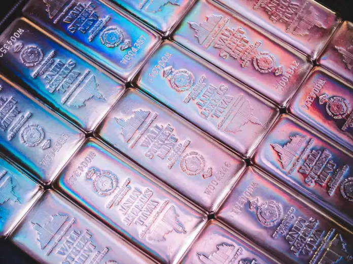 The bearish read on silver looks obvious: the metal fell from $70.98 on June 15, 2026 to around $59 by June 26 as a US–Iran ceasefire drained the haven bid, and solar demand — silver's great growth story — just dropped 19% in a single year. Yet that is exactly the misread. The Silver (XAG) price prediction case for the rest of 2026 rests on a paradox the headlines miss: solar is using less silver, and the structural deficit is getting worse anyway, because artificial-intelligence (AI) data-centre and automotive demand are growing faster than solar is shrinking. The late-June drop was a geopolitical unwind in a structurally tight market, not a demand collapse.
Here is the angle that reframes the whole forecast. Silver in 2026 is not one market but three pricing engines stacked on top of each other — a haven trade that moves with gold, an industrial commodity tied to the energy transition and AI build-out, and a monetary metal sensitive to real yields and the Federal Reserve. When those three pull together, you get the J.P. Morgan base case toward $85; when they pull apart, you get the kind of $12 round-trip silver just printed. The gold-to-silver ratio is the cleanest gauge of which engine is in control, and at roughly 61:1 it is telling you silver has room to catch up — if the deficit thesis holds.
<strong>Key Facts:</strong>
<blockquote>
• Silver traded near $59 on June 26, 2026, after peaking at $70.98 on June 15 — <a href="https://goldsilver.com/industry-news/article/silver-price-outlook-june-2026/">GoldSilver</a>, June 2026
• J.P. Morgan holds a 2026 average forecast of $81/oz and a Q4 target of $85/oz — <a href="https://www.naga.com/en/news-and-analysis/articles/silver-forecast-and-price-predictions">market forecasts</a>, 2026
• UBS trimmed its year-end target to $80/oz and sees silver "broadly sideways" — <a href="https://www.kitco.com/news/article/2026-05-14/silver-price-outlooks-chopped-supply-deficit-forecasted-narrow-dramatically">Kitco</a>, May 2026
• 2026 marks a sixth consecutive annual market deficit; the World Silver Survey puts the shortfall at 46.3 million ounces, up 15% on 2025 — <a href="https://silverinstitute.org/global-silver-investment-to-remain-strong-in-2026-against-the-backdrop-of-a-sixth-consecutive-annual-market-deficit/">Silver Institute</a>, 2026
• Solar photovoltaic silver demand fell 19% to roughly 151 million ounces — the largest single-year drop on record, driven by thrifting not substitution — <a href="https://goldsilver.com/industry-news/article/silver-supply-deficit-solar-thrifting/">Silver Institute / GoldSilver</a>, 2026
• At a 60:1 gold-silver ratio silver implies about $72; at 55:1 it implies roughly $79 against current gold — ratio math, June 2026
</blockquote>
What is actually happening with the silver price in 2026
Every Silver (XAG) price prediction in mid-2026 starts from the same volatile setup: a metal that ran to $70.98 on safe-haven and deficit demand, then gave back roughly $12 in eleven days when the US–Iran ceasefire removed the geopolitical premium. That round-trip is the headline, but the structure underneath has not changed. The silver market is in its sixth straight year of supply deficit, with Metals Focus' World Silver Survey 2026 putting the shortfall at 46.3 million ounces and continued drawdowns of London and COMEX vault stocks acting as a price-support mechanism. Mine production is forecast to rise just 1% to 820 million ounces against total supply near 1.05 billion ounces — a decade high that still does not close the gap.
The demand side is where the misread happens. Solar photovoltaic silver use fell 19% in 2026 to about 151 million ounces, the steepest single-year drop on record. That sounds bearish until you see why: it is thrifting — manufacturers applying thinner conductive paste and tightening contact geometry to use less silver per panel — not customers leaving silver for another metal. Meanwhile the Silver Institute flags structural growth in data centres, AI infrastructure and the automotive sector that partly offsets the solar pullback. The net result is the paradox: less silver per solar cell, a wider overall deficit. For investors, the lesson is that silver's industrial demand has diversified beyond a single end-market, which makes the deficit more durable, not less.
The structural bulls see this as the early innings of a multi-year repricing.
<blockquote>
Silver could reach "$100 in short order" once it confidently clears resistance, and "eventually $300" if industrial demand keeps outpacing supply.
— <strong>Peter Krauth</strong>, author of <em>The Great Silver Bull</em> and editor of Silver Stock Investor (<a href="https://www.sbcgold.com/blog/silver-is-gunning-for-50-and-eventually-300-peter-krauth/">Scottsdale Bullion & Coin</a>)
</blockquote>
How analysts are splitting on the XAG price prediction
The forecasting community is unusually divided, and the spread defines the trade. On the steady-base side, J.P. Morgan maintains a 2026 average of $81/oz and a Q4 target of $85/oz — more than double silver's 2025 average — anchored to the persistent deficit and resilient investment demand. The Reuters analyst poll lands close, with a $79.50 median. These are not moonshots; they imply silver recovering most of the lost ground from the June correction without needing a new geopolitical shock.
The cautious camp is led by UBS, which cut its numbers after concluding the deficit would narrow more than feared. UBS strategists Wayne Gordon and Dominic Schnider trimmed their year-end target to $80/oz and reset the path lower across every horizon.
<blockquote>
"Consistent with the smaller deficit, we have trimmed our price outlook across all forecast horizons. In our base case, we expect silver to trade broadly sideways."
— <strong>Wayne Gordon and Dominic Schnider</strong>, Strategists, UBS (<a href="https://www.kitco.com/news/article/2026-05-14/silver-price-outlooks-chopped-supply-deficit-forecasted-narrow-dramatically">Kitco</a>)
</blockquote>
The two camps are not as far apart as they look — both cluster around $80–$85 for the base case. The real disagreement is over the tails: whether the deficit and a falling gold-silver ratio drag silver toward $100, or whether a holding ceasefire and a hawkish Fed cap it near $55. FinanceFeeds covered the downside technically in its note on the <a href="https://financefeeds.com/silver-breakdown-signals-deeper-drop-toward-55-00-24-june-2026/">silver breakdown pointing toward $55</a>, and the upside macro in its <a href="https://financefeeds.com/gold-xau-price-prediction-2026-2028-2030/">Gold (XAU) price prediction</a> — silver's senior partner in the precious-metals trade.
Silver price targets 2026: scenario by scenario
Turning the debate into a concrete Silver (XAG) price prediction means defining scenarios with explicit triggers. The base case sees silver recovering toward $85 by year-end, in line with J.P. Morgan, as the deficit and vault drawdowns reassert themselves once the geopolitical premium fully clears. The bull case to $106 requires the gold-silver ratio to keep compressing while gold pushes toward major-bank targets. The bear case to $55 fires if the ceasefire holds, real yields rise under a hawkish Fed, and investment demand keeps unwinding.
ScenarioXAG/USD targetImplied move from $59Primary trigger
<strong>Bull</strong>$106 (Krauth sees $100+)+80%Gold-silver ratio compresses below 55:1; gold rallies to bank targets
<strong>Base</strong>$85 (JPM Q4)+44%Deficit reasserts; vault drawdowns support; haven premium clears
<strong>Bear</strong>$55-7%Ceasefire holds; real yields rise; investment demand unwinds
<em>Sources: J.P. Morgan (base $85), Krauth/Scottsdale (bull $100+), FinanceFeeds technical ($55 breakdown), UBS (sideways near $80). Gold-silver ratio math against current gold. Targets are 2026 scenarios as of June 30, 2026.</em>
Where does the ratio point? The gold-to-silver ratio is the single most useful framework here. At roughly 61:1 in mid-June 2026, silver is neither cheap nor expensive against gold by historical standards — but the direction of travel matters. In prior bull cycles the ratio compressed to 55:1 or below as silver outran gold late in the move. Run the math against gold's own 2026 strength: at 60:1 silver implies about $72, at 55:1 roughly $79, and against the London Bullion Market Association's 2026 gold consensus near $4,742 those implied prices rise to $79 and $86. If gold pushes toward the $5,400–$6,000 targets some banks now carry, a 55:1 ratio mechanically places silver near $100 — which is how a $59 spot price and a $106 bull case can sit in the same forecast without contradiction.
The macro and geopolitical tension shaping silver
Two forces will decide which scenario wins. The first is the Federal Reserve. Silver pays no yield, so its opportunity cost rises when real yields rise — and the Fed under new Chair Kevin Warsh held rates at 3.50–3.75% on June 17, 2026 while signalling hikes rather than cuts. A genuinely hawkish path lifts real yields and is the clearest headwind to the bull case, the mechanism behind the $55 bear scenario. The same dynamic is capping rate-sensitive assets across markets, a theme running through silver, gold and the broader risk complex this summer.
The second force is geopolitics, and it cuts both ways. The June US–Iran ceasefire is what triggered the correction; if it holds, the haven premium stays drained and silver leans on industrial demand and the deficit alone. If it frays, the haven bid returns fast — silver's $12 round-trip in eleven days shows how violently the metal repositions on headlines. This is why UBS, even while trimming, still expects a deficit of roughly 60–70 million ounces — larger than the World Silver Survey's 46.3-million-ounce figure, a reminder that even the bears disagree only on the magnitude of the shortfall, not its existence. A market in its sixth straight deficit does not need much to squeeze.
The vault squeeze the bears underweight
There is a supply-side mechanism that rarely makes the price-target headlines but matters enormously for how violently silver can move: the shrinking pool of freely available metal. A market can run a deficit for years while prices stay calm if there are large above-ground stockpiles to draw down — but those stockpiles are finite. Metals Focus' Philip Newman has pointed to the physical liquidity squeeze that hit in late 2025, when London vault stocks fell to a historic low of roughly 17% unencumbered, meaning the share of metal genuinely free to trade had collapsed. A sixth straight deficit in 2026 draws that pool down further.
This is why investment demand is the swing factor the cautious camp underweights. Physical investment demand is forecast near 227 million ounces in 2026, and silver-backed exchange-traded products amplify the effect: when investors add to holdings, they pull metal out of the same vaults industry needs, tightening the float on both sides at once. A market that is structurally short and thin on freely available inventory is precisely the kind that produces the $12 round-trips silver just printed — and, on the upside, the squeezes that take spot to levels no smooth forecast predicts. The deficit sets the direction; the float sets the violence.
What happens next: the silver price prediction for the rest of 2026
Three predictions follow. First, expect silver to trade a wide $55–$90 band through the third quarter, with the $85 base case the most probable year-end outcome as the deficit reasserts itself once the geopolitical premium fully clears. Second, the gold-silver ratio is the leading indicator to watch: a sustained move below 60:1 confirms the catch-up trade and opens the path toward $100, while a climb back above 70:1 signals the bear case is winning. Third, the $100-plus bull case is a real possibility but a conditional one — it needs gold to keep rallying and the Fed to stop hiking, and the second condition looks unlikely before year-end.
For brokers, platforms and commodity desks, the takeaway is that silver's 2026 path is a function of the ratio and the real-yield environment more than any single demand number. The structural deficit is the floor under the story; the Fed and the ceasefire set the ceiling. For comparison with another scenario-based forecast navigating the same hawkish-Fed backdrop, see our <a href="https://financefeeds.com/intel-intc-stock-forecast-150-bull-90-bear-2026/">Intel (INTC) stock forecast</a>. Watch the September Fed meeting and the gold-silver ratio as the two cleanest tells for which scenario silver ultimately prints.
FAQ
What is the silver (XAG) price prediction for 2026?
The base case targets $85 by year-end, in line with J.P. Morgan's Q4 forecast, up from around $59 on June 26, 2026. The bull case is $106 or higher if the gold-silver ratio compresses, and the bear case is $55 if a holding ceasefire and a hawkish Fed unwind the haven and investment bid.
Why did the silver price fall in late June 2026?
Silver dropped from $70.98 on June 15 to around $59 by June 26 after a US–Iran ceasefire removed the geopolitical safe-haven premium. The move was a haven unwind, not a demand collapse — the underlying structural deficit remained intact.
Is silver still in a supply deficit in 2026?
Yes. 2026 marks the sixth consecutive annual market deficit. Metals Focus' World Silver Survey puts the shortfall at 46.3 million ounces, while UBS, even after trimming, sees 60–70 million ounces. Vault drawdowns in London and on COMEX are cited as a key price support.
Why is solar using less silver but the deficit is widening?
Solar photovoltaic demand fell 19% to roughly 151 million ounces in 2026, but through thrifting — using less silver per panel — not substitution. At the same time, AI data-centre, automotive and investment demand grew, so the overall market deficit widened despite the solar pullback.
Could silver reach $100 in 2026?
It is possible but conditional. A gold-silver ratio compressing below 55:1 while gold rallies toward $5,400–$6,000 bank targets would place silver near $100 mechanically. Bulls such as Peter Krauth see $100 "in short order," but it requires gold strength and a Fed that stops hiking.
How does the Federal Reserve affect the silver price?
Silver pays no yield, so higher real yields raise its opportunity cost. With the Fed signalling hikes under Chair Kevin Warsh in June 2026, rising real yields are the main headwind to silver's bull case and the core driver of the $55 bear scenario.
<em>This article is informational analysis only and is not financial, investment, or trading advice. Commodity and precious-metals markets are highly volatile and prices can move sharply against any forecast; price targets are scenario estimates, not guarantees. Past performance and analyst projections do not guarantee future results. Do your own research and consult a regulated financial adviser before making any investment decision.</em>