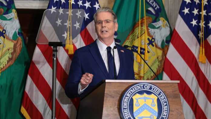 Newly appointed Treasury Secretary Scott Bessent has been making waves and headlines during his brief stint as the country’s top economic official.
Bessent has been forced by his own policies to become more of an activist, as the U.S. 30-year Treasury yield reached a nearly two-decade high of 5.34% earlier this month, <a href="https://www.reuters.com/business/us-treasury-buyback-briefly-eases-bond-rout-debt-worries-persist-2026-08-20/">Reuters</a> reported.
That prompted the <a href="https://home.treasury.gov/news/press-releases/sb0607">Treasury Department to announce</a> that it would at least double its liquidity-support buybacks for bonds maturing in 10 to 30 years, while also doubling the cap from $2 billion to at least $4 billion per operation between Sept. 9 and Nov. 4.
The market’s reaction to the move was predictable, temporarily lowering yields before they immediately rebounded days later.
Treasury 10-year bond yields were sitting at 4.64% at last check Tuesday, Aug. 25, ahead of its pre-announcement levels, according to <a href="https://www.cnbc.com/quotes/US30Y">CNBC</a>. Meanwhile, the 30-year yield was 5.174%, hovering near pre-announcement levels, CNBC also noted.
James Sullivan, JPMorgan’s co-head of global fundamental research, <a href="https://www.thestreet.com/economy/j-p-morgan-just-poured-cold-water-on-bessents-bond-fix">recently compared Bessent’s plan</a> to “paying your mortgage with your credit card.”
While it doesn’t take an MBA to know that Bessent’s short-term relief play would backfire, billionaire investor and former Bessent colleague Stanley Druckenmiller wrote an op-ed this week pointing out the folly in Bessent’s approach.
Stanley Druckenmiller takes aim at Bessent’s bond liquidity approach
U.S. economic policies have been under scrutiny recently as the national debt ballooned to $40 trillion for the first time.
Perhaps most distressingly, the debt was just $20 trillion in 2017, meaning it has doubled over the past nine years, <a href="https://www.crfb.org/papers/qa-everything-you-should-know-about-debt-ceiling-mar-2017">Committee for a Responsible Federal Budget</a> confirmed. U.S. debt first reached $1 trillion in 1941.
It is a pattern of kicking the can down the road that markets are correctly rejecting, investor Stanley Druckenmiller said in his <a href="https://www.wsj.com/opinion/let-the-bond-market-speak-81529d74">Wall Street Journal</a> opinion piece this week.
“I have spent five decades trading on a simple premise: Markets aggregate information no committee possesses, and prices are how that information reaches decision makers,” Druckenmiller said. “The long-term Treasury yield is the most important price in the world. It is also the only fiscal disciplinarian the U.S. has left.
“The market’s verdict was swift and correct: This wasn’t liquidity management, it was price management — and a mistake far larger than $4 billion suggests.”
Druckenmiller knows Bessent well. The two worked together at the Quantum Fund and Soros Fund Management. But that didn’t stop Druckenmiller from pressing his former colleague about his bond liquidity play.
<strong><a href="https://www.thestreet.com/fed/bessent-40-trillion-debt-fed-rate-hike">Related: Bessent’s $40 trillion debt answer puts Fed rate hike in focus</a></strong>
“Suppressed long rates sugarcoat the interest-cost projections, shrink the apparent urgency, and let incumbents assure voters the debt is someone else’s problem,” Druckenmiller wrote.
“Return buybacks to their stated purpose: small, scheduled, off-the-run liquidity operations announced at quarterly refundings, never off-cycle responses to yield levels. Term out the debt honestly and pay the price the market sets,” Druckenmiller said.
“A credible fiscal package would do more for the long end of the curve than a buyback program 1,000 times this size.”
Investor Stanley Druckenmiller criticized Treasury Secretary Scott Bessent’s bond liquidity strategy.<a href="https://www.gettyimages.com/detail/2291861008">Chip Somodevilla / Getty Images</a>
Druckenmiller op-ed criticized for AI use
While Druckenmiller took aim at Bessent’s recent policy decision, online sleuths took aim at Druckenmiller’s op-ed by running it through AI-detection tools.
“Sorry, but this is the most obviously AI-generated op-ed ever,” said Joey Politano on <a href="https://x.com/JosephPolitano/status/2092077428122206335">X</a> (the former Twitter). Politano’s newsletter offers “data-driven insights on economics and business.”
“It has ‘it’s not X, it’s Y’ construction in both the first two paragraphs,” he said. “Panagram (AI detection) has it as 100% AI.”
When reached for comment about his use of AI for the op-ed, Druckenmiller didn’t think there was an issue.
“There’s a reason I moved from an English major to being an economics major,” Druckenmiller <a href="https://www.notus.org/media/stanley-druckenmillers-wsj-op-ed-bessent-ai">told Notus</a>. “I’m not embarrassed by it … I write everything using AI now for the same reason I use a calculator when I do math problems. I don’t know why this is relevant. My name is on the piece. It’s my message.”
Politano wasn’t impressed.
“One of the most prominent finance billionaires submitted this? The WSJ just ran it? Are there no standards anymore?” he asked.
While the <a href="https://www.wsj.com/news/author/wsj-artificialintelligencetools">Journal’s internal guidelines</a> state that “work that includes AI inputs is reviewed by a journalist before publishing,” it did not immediately return a request for comment about whether Druckenmiller’s op-ed runs afoul of its editorial guidelines.
Notus points out that earlier this month, Harvard professor Ricardo Hausmann published a guest column in the <a href="https://www.ft.com/content/7ff4321e-3f96-4f7b-8f2d-4fefa4773a5d?sharetype=blocked">Financial Times</a> about President Donald Trump’s tariff war and was also called out by the public for obviously using AI.
FT later added a note saying, “It has come to our attention that AI was used to condense a longer draft of this column prior to submission to the FT and our own editorial involvement. The FT editorial code of conduct specifically prohibits the use of AI in the writing process.”
<strong><a href="https://www.thestreet.com/markets/scott-bessent-doubles-treasury-bond-buybacks-market">Related: Scott Bessent just made a bold move on the bond market</a></strong>