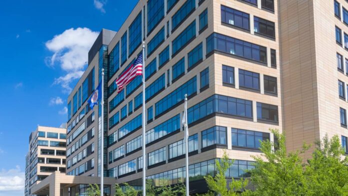 UnitedHealth Group (<a href="https://www.thestreet.com/quote/UNH">UNH</a>) <strong>beat <a href="https://www.thestreet.com/dictionary/w/wall-street">Wall Street</a>'s numbers</strong> on July 16, 2026, but its chief financial officer spent the <a href="https://www.thestreet.com/dictionary/e/earnings-call">earnings call</a> making sure nobody mistook that result for a solved cost problem.The company beat earnings estimates by <strong>roughly 30%,</strong> and management raised full-year guidance well past analysts' expectations.Yet the UnitedHealth executive closest to the numbers refused to call it a turning point in costs.CFO <strong>Wayne DeVeydt's</strong> comments to reporters conveyed something different from the earnings release, and they are worth paying attention to.What UnitedHealth reported in the second quarter of 2026According to <a href="https://ng.investing.com/equities/united-health-group-earnings#:~:text=UnitedHealth%20Q2%20adjusted%20EPS%20of%20%246.38%20beat%20estimates%20by%2031.6%25%3B%20revenue%20of%20%24112B%20slightly%20topped%20forecasts%2C%20driving%20shares%20up%207.61%25%20premarket">Investing.com</a>, UnitedHealth posted adjusted earnings of <strong>$6.38 a share</strong> on revenue of <strong>$112.0 billion</strong>. That beat analyst expectations of <strong>$4.90 a share on $110.85 billion</strong>.<strong>Net income</strong> reached <strong>$5.48 billion</strong>, up from <strong>$3.41 billion</strong> a year earlier.Operating earnings <strong>rose</strong><strong>55% to $8.0 billion</strong>, and the company reported <strong>$11.1 billion</strong> in cash flows from operations, or <strong>1.9 times net income</strong>, <a href="https://finance.yahoo.com/markets/stocks/articles/unitedhealth-stock-soars-q2-earnings-120147363.html">Yahoo Finance</a> reported.<strong>More Healthcare Coverage:</strong><a href="https://www.thestreet.com/health/mark-cuban-warns-ai-could-make-us-healthcare-even-worse"><strong>Mark Cuban warns AI could make US healthcare even worse</strong></a><a href="https://www.thestreet.com/health/medicaid-5-year-lookback-rule-nursing-home-asset-transfers"><strong>Medicaid's 5-year rule catches families off guard</strong></a><a href="https://www.thestreet.com/health/gallup-ozempic-glp-1-use-soars"><strong>GLP-1 weight-loss drug popularity reaches new heights with Americans</strong></a>UnitedHealth's management then raised full-year adjusted earnings guidance to a range of <strong>$19.50 to $20.00 a share</strong>.That's up from a prior view of <strong>more than $18.25</strong> and maintains revenue guidance <strong>above $439 billion</strong>.Although analysts had expected a rise, they didn't expect one of that size, Healthcare Dive reported.
UnitedHealth shares traded near $423 on July 17, up about 26% year-to-date, after the insurer raised its 2026 profit outlook.<a href="https://www.gettyimages.com/detail/540839640">Wolterk / Getty Images</a>
Why the medical care ratio did most of the workThe <strong>medical care ratio</strong> drove the quarter. It shows how much of every premium dollar goes to <strong>paying claims</strong>.The number <strong>fell to</strong><strong>86.7% from 89.4%</strong> a year earlier, and a lower ratio means the <strong>insurer keeps more</strong> of each premium dollar.For context, the second quarter's <strong>86.7% ratio</strong> looks great next to last year's <strong>89.4%</strong>. But it's worse than the <a href="https://www.thestreet.com/investing/stocks/jpmorgan-resets-unitedhealth-stock-target-for-2026">first quarter's</a><strong>83.9%</strong>. That means costs are improving year over year, not quarter over quarter.Part of that improvement came from <strong>$860 million</strong> in favorable <strong>reserve development</strong>, plus a <strong>milder flu season</strong>. Executives credited these, along with <strong>benefit changes</strong> and <strong>network adjustments</strong>, in remarks reported by <a href="https://www.uhc.com/agents-brokers/employer-sponsored-plans/news-strategies/annual-health-trends-report">UnitedHealthcare</a>. Reserve releases and a mild flu season are real money. But they're <strong>one-time boosts</strong>, not proof that care is getting cheaper to provide.What CFO Wayne DeVeydt said cuts against the beatCFO <strong>Wayne DeVeydt</strong> didn't sugarcoat his words. Medical costs stayed "elevated over historical levels," he said.DeVeydt told <a href="https://www.cnbc.com/2026/07/16/unitedhealth-group-unh-earnings-q2-2026.html">CNBC</a> that the results reflect efforts to push down an already high number, not a sign that costs are actually coming under control.<strong><a href="https://www.thestreet.com/investing/jim-cramer-moderna-stock-buy-mrna-pipeline">Related: Jim Cramer turns bullish on health care stock after years of doubt</a></strong>He described the recovery as a "multi-year journey," even as he said the cultural turnaround was translating into strong earnings, <a href="https://tradersunion.com/news/financial-news/show/2694982-unitedhealth-raises-2026-profit-outlook-q2-earnings/">Traders Union</a> reported.Read plainly, he is saying the company got better at <strong>managing expenses</strong>. The costs themselves didn't get cheaper.That distinction matters for 2027 forecasts. Pricing discipline can only go so far. Cost trends don't have that limit.The membership number that explains the strategyHere's where the trade-off shows up. UnitedHealthcare served <strong>48.5 million members</strong> this quarter, <strong>down about 525,000</strong> from the prior quarter.DeVeydt said <strong>higher premiums</strong> and <strong>smaller benefits</strong> are pushing people out of ACA exchange plans and Medicare Advantage. He expects the company to lose<strong> roughly 500,000 exchange members</strong> and <strong>1.1 million Medicare Advantage members</strong> in 2026.Higher prices are making up for the lost members, so revenue still holds steady. However, DeVeydt admitted that's not a healthy trend for the system long term.<strong>The loop works like this</strong>:<strong>Medical costs</strong> run above historical levelsUnitedHealth <strong>raises premiums</strong> and trims benefits to protect marginCoverage gets <strong>less affordable</strong>, and members leave<strong>Revenue</strong> stays flat because price replaces volumeMargin went up, and Membership went down at the same time.Where commercial costs are still moving wrongMedicare was the bright spot, as UnitedHealthcare CEO <strong>Tim Noel</strong> said the company is not yet seeing costs slow down in its commercial business.As a result, the growth cost there is now running <strong>slightly above the 11%</strong> pace it reported earlier, according to <a href="https://www.healthcarefinancenews.com/news/unitedhealth-raises-outlook-q2-profit-jumps-55b">Healthcare Finance News</a>.<strong>Dan Kueter</strong>, who runs the commercial unit, blamed part of that on a <strong>billing dispute process</strong> tied to the <strong>No Surprises Act</strong>. He said it is adding about <strong>half a percentage point</strong> to costs this year and now accounts for at least one full point of the total commercial cost increase."Simply put, we're not yielding the full margin expansion for which we planned in 2026," Kueter said.That is a plain admission of a problem, tucked inside a quarter that the market read as a clean win.How UNH stock has performed against the marketThe stock <strong>closed at $423.38</strong> on <strong>July 17</strong>, up <strong>about 26%</strong> for the year and <strong>nearly 6%</strong> over the past month. That puts its market value <strong>near $384 billion</strong>, with shares trading at <strong>about 32 times earnings</strong>.The <strong>52-week range</strong> runs from <strong>$234.60 to $461.62</strong>. That's how sharp the swing has been.<a href="https://www.thestreet.com/investing/stocks/jpmorgan-resets-unitedhealth-stock-target-for-2026">UNH gained 5.6%</a> on July 16 after the report, even as the Nasdaq and <a href="https://www.thestreet.com/dictionary/s/s-p-500">S&P 500</a> fell and semiconductors slid.<strong>Quick comparison of where UNH sits</strong>:<strong>Measure</strong><strong>UNH</strong>Year to date+25.86%Past month+5.97%Dividend yield2.19%P/E ratio31.98UNH still <strong>trades below its 52-week high</strong>, so the recovery is real but incomplete.What still has to go right for the guidance to holdThree things have to go right in 2026.<strong>Medicare costs have to stay under budget. </strong>Noel said Medicare costs are still running high by historical standards. However, they're coming in below the 10% increase UnitedHealth planned for when it built its 2026 benefits. If that changes, margins could shrink fast.<strong>The commercial unit has to stop deteriorating</strong>. Kueter already said the planned margin expansion is not landing.<strong>Reserve development cannot be the crutch</strong>. The $860 million release helped this quarter and may not repeat.DeVeydt said he expects <strong>Optum Health revenue growth</strong> to fully return in 2028, which is a useful reminder of the timeline UNH’s management itself is working with.What this means if you own UNH or are watching itIf you already own the stock, the case got stronger. But <strong>pay attention</strong> to why.The margin gains came from higher prices, membership cuts, and reserve releases. Not from care actually getting cheaper.Those levers only work for so long. DeVeydt knows that, and he didn't pretend otherwise.<strong>If you're thinking about buying in</strong>, know this: the stock is already up more than <strong>25%</strong> this year. Much of the good news is priced in.<strong>Watch two things</strong> next quarter. Does the medical care ratio hold up without another reserve release? Does commercial cost growth finally level off?If you get your coverage through UnitedHealthcare, the impact is clear: The same cost discipline that lifted the company's profits shows up for you as a higher premium or a thinner plan at renewal. About 1.6 million people are expected to leave UnitedHealth's plans this year for that reason.That's the trade DeVeydt described. He didn't try to dress it up.<strong><a href="https://www.thestreet.com/health/ionis-pharmaceuticals-failed-wainua-drug-trial">Related: Panic grips Ionis Pharmaceuticals investors amid bad news spree</a></strong>