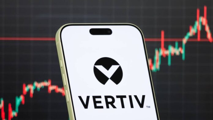 Investors tend to hesitate before buying a stock that has already climbed more than 1,000%, as that kind of gain usually signals the easy money is gone.
However, Mike Khouw just said something noteworthy on a stock like that.
On CNBC’s “Options Action,” the veteran options trader presented a bullish case on <strong>Vertiv Holdings Co.</strong> (VRT).
He also structured an <strong>options trade</strong> stretching into <strong>early 2027</strong>.
Khouw has spent over two decades in the markets as a strategist, portfolio manager, and proprietary trader.
He has appeared on CNBC’s Fast Money and Options Action since 2009, which makes his opinion on risk valuable for investors.
According to Khouw, where the stock’s earnings are heading is the most important thing.
What Vertiv does and why AI spending fuels its growth
Vertiv builds the power and cooling systems that data centers use.
The chips used in data centers often generate a lot of heat and consume large amounts of electricity. Vertiv sells the equipment that manages both.
That makes Vertiv a supplier to the entire AI buildout.
In its second quarter of 2026, <a href="https://investors.vertiv.com/news/news-details/2026/Vertiv-Reports-Strong-Second-Quarter-2026-with-Diluted-EPS-Growth-of-53-Adjusted-Diluted-EPS-Growth-of-60-Raises-Full-Year-2026-Guidance-Across-All-Key-Metrics/default.aspx">Vertiv</a> reported revenue of <strong>$3.27 billion</strong>, <strong>up 24%</strong> from a year earlier.
Adjusted operating margins expanded <strong>410 basis points</strong> to <strong>22.6%</strong>, which is a sign that the company can raise prices while it grows.
<strong>More AI Stocks:</strong>
<strong><a href="https://www.thestreet.com/investing/stocks/jim-cramer-names-six-stocks-nvidia-coreweave-nebius-ai-data-center-trade">Jim Cramer says the AI data center trade is back, names 6 stocks</a></strong>
<strong><a href="https://www.thestreet.com/investing/stocks/wall-street-sees-near-40-percent-upside-for-broadcom-avgo-stock">Wall Street sees nearly 40% upside for one AI chip giant</a></strong>
<strong><a href="https://www.thestreet.com/investing/stocks/nvidia-vera-cpu-strong-signal-to-amd-intel-investors">Nvidia just sent a strong signal to AMD and Intel investors</a></strong>
Vertiv’s management also raised its full-year 2026 adjusted earnings guidance to a <strong>midpoint of $6.70 per share</strong>, <strong>up 60%</strong> over 2025.
Vertiv builds the power and cooling systems that keep AI data centers running.<a href="https://www.gettyimages.com/detail/2259521244">Cheng Xin / Getty Images</a>
Why the stock’s high price tag still looks justified
Vertiv trades at a forward price-to-earnings multiple of <strong>roughly 63 times earnings</strong>. That means investors expect a strong performance.
One way to check whether that price is justified is the PEG ratio, which compares a stock’s valuation with its earnings growth rate.
Trackers put Vertiv’s PEG <strong>below 1</strong>, which suggests the stock’s earnings growth matches, or is ahead of its high price tag.
Vertiv also joined the S&P 500 in <strong>March 2026</strong>.
That addition brought steady buying from index funds, which helped the stock hold up during broader AI selloffs earlier this year.
The risks investors should weigh before buying
Vertiv carries a beta of <strong>about 2.07</strong>, which means it tends to move roughly twice as much as the overall market.
High-multiple names also react strongly to bad news. A slowdown in AI spending, or a broad market pullback could trigger a steep drop.
<strong><a href="https://www.thestreet.com/investing/stocks/bmo-sets-broadcom-avgo-stock-target-to-455-outperform">Related: BMO sees writing on the wall for Broadcom stock after earnings</a></strong>
Vertiv stock declined on concerns about supply chain delays that pushed some sales into the back half of the year, <a href="https://finance.yahoo.com/markets/stocks/articles/vertiv-q2-2026-earnings-revenue-121320056.html">Yahoo Finance</a> reported. Then it recovered.
How to approach a stock like Vertiv
The demand for data center power and cooling shows no clear sign of slowing.
For investors who want exposure, a measured approach helps:
<strong>Size the position carefully</strong>. A high-beta stock can be volatile, so avoid putting too much at once.
<strong>Balance it out</strong>. Pairing a growth stock like VRT with steadier sectors can cushion losses during a selloff.
<strong>Watch AI capital spending</strong>. If hyperscaler budgets tighten, Vertiv’s growth would face its first real test.
Khouw’s call rests on the idea that Vertiv’s growth has more room ahead, and he says investors shouldn’t be scared by past gains.
Still, a stock priced for strong results often leaves little margin for error.
<strong><a href="https://www.thestreet.com/investing/stocks/mrvl-marvell-google-custom-chip-deal-warrant">Related: Marvell investors must carefully consider latest Google deal</a></strong>