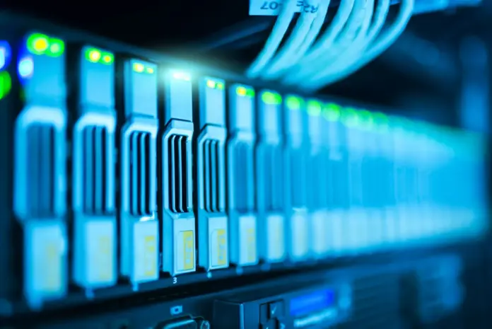 The market has decided the artificial-intelligence infrastructure trade is exhausted — Vertiv (NYSE: VRT) has fallen roughly 36% from its May peak of $376.23 to $241.57 as of the July 31, 2026 close, per <a href="https://stockanalysis.com/stocks/vrt/">stockanalysis.com</a>. The problem with that verdict is that it was delivered in the same fortnight that Vertiv raised full-year guidance across every key metric, reported a backlog above $15 billion, and watched its largest end-customers — the AI labs — sign the biggest compute contracts in history. A vrt stock prediction built on the actual order book rather than the tape looks very different from one built on momentum, and that gap between what the sellers see and what the backlog says is the entire investment question this piece works through.
Here is the synthesis competing coverage keeps missing: the demand signals and the share price are moving in opposite directions <em>at the same time</em>. In the two weeks Vertiv shares were de-rating, CoreWeave completed its sweep of all four top AI labs with a multi-year Anthropic deal, per <a href="https://datacentremagazine.com/news/coreweave-powering-openai-meta-and-anthropics-ai-future">Data Centre Magazine</a>; OpenAI's Stargate build with Oracle targeted 10 gigawatts of capacity by year-end, per <a href="https://intuitionlabs.ai/articles/oracle-openai-300b-deal-analysis">IntuitionLabs' deal analysis</a>; and AMD bought its way into Anthropic's supply chain with a 2-gigawatt commitment FinanceFeeds covered in <a href="https://financefeeds.com/the-ai-chip-selloff-deepens-sk-hynix-14-65-amd-8-3-and-why-august-earnings-could-decide-the-sector/">the AI chip selloff analysis</a>. Every one of those gigawatts needs power distribution, switchgear, busway, and liquid cooling — which is to say, every one of those gigawatts is a Vertiv purchase order that has not been booked yet. Having tracked the AI-infrastructure names through the July selloff, the pattern rhymes less with a bubble deflating than with 2018-style capex indigestion: violent, sentiment-driven, and resolved by the next order print.
<strong>Key facts</strong>
VRT closed July 31, 2026 at <strong>$241.57</strong>, up 6.2% on the day but ~36% below its 52-week high of $376.23 — <a href="https://stockanalysis.com/stocks/vrt/">stockanalysis.com, July 31, 2026</a>
Q2 2026 net sales of <strong>$3,274 million</strong>, organic growth of 18%, roughly 3% below consensus — <a href="https://www.prnewswire.com/news-releases/vertiv-reports-strong-second-quarter-2026-with-diluted-eps-growth-of-53-adjusted-diluted-eps-growth-of-60-raises-full-year-2026-guidance-across-all-key-metrics-302837598.html">Vertiv Q2 release, July 29, 2026</a>
Adjusted diluted EPS of <strong>$1.52</strong>, up 60% year-on-year; adjusted operating margin 22.6% — Vertiv Q2 release
Adjusted free cash flow of <strong>$925 million</strong> in the quarter — Vertiv Q2 release
Full-year 2026 guidance <strong>raised</strong> to ~$14.0 billion net sales and $6.70 adjusted EPS at the midpoint — Vertiv Q2 release
Project backlog above <strong>$15 billion</strong>, with five plant expansions under way — <a href="https://simplywall.st/stocks/us/capital-goods/nyse-vrt/vertiv-holdings-co/news/how-raised-2026-guidance-and-ai-data-center-demand-at-vertiv">Simply Wall St, August 2026</a>
Consensus price target <strong>$355.42</strong> across 28 analysts (range $236–$500), rating Strong Buy — <a href="https://stockanalysis.com/stocks/vrt/forecast/">stockanalysis.com forecast page, August 2026</a>
<strong>Quick take:</strong> Vertiv raised guidance to ~$14 billion in sales and $6.70 adjusted EPS, carries a $15 billion-plus backlog, and generated $925 million of quarterly free cash flow — yet trades 36% below its May high because one revenue line landed 3% light. The dispute is not about the company; it is about how long the AI capex cycle runs. Bull $375, base $355, bear $180.
What actually happened in Q2 — and what the selloff is pricing
Vertiv's July 29 print was, on its face, the kind of quarter growth investors order from a catalogue: net sales of $3.27 billion, adjusted diluted EPS up 60% to $1.52, adjusted operating margin at 22.6%, and $925 million of adjusted free cash flow. The company raised full-year guidance across all key metrics, to roughly $14 billion of net sales and $6.70 of adjusted EPS at the midpoint. The blemish was the top line landing about 3% — roughly $104 million — below consensus, which management attributed to project timing delays it expects to resolve in the second half, supported by five plant expansions and ramping international capacity, per the company's release and <a href="https://seekingalpha.com/article/4927566-vertiv-slump-is-your-chance-to-buy-earnings-review">Seeking Alpha's earnings review</a>.
In a calmer tape, a 3% timing miss against a 60% EPS beat-and-raise gets shrugged off. But Vertiv reported into the most nervous AI tape of the year — the week FinanceFeeds chronicled SK Hynix falling 14.65% in a session and the KOSPI halting on an 8% plunge. The de-rating, in other words, is a statement about the <em>sector's</em> multiple, not about Vertiv's execution. That is precisely the setup where scenario analysis earns its keep. "This quarter reflects the compounding effect of years of deliberate investment in technology, capacity, and customer partnerships," said Giordano Albertazzi, Chief Executive Officer of Vertiv, in the <a href="https://www.prnewswire.com/news-releases/vertiv-reports-strong-second-quarter-2026-with-diluted-eps-growth-of-53-adjusted-diluted-eps-growth-of-60-raises-full-year-2026-guidance-across-all-key-metrics-302837598.html">earnings release</a>.
The demand side: every announced gigawatt is an unbooked order
Vertiv sells the unglamorous half of the AI buildout: power distribution units, switchgear, uninterruptible power supplies, thermal management and, increasingly, the liquid-cooling loops that dense GPU racks cannot run without. Its order flow therefore lags the headline compute deals by design — the chips are contracted first, the facility infrastructure is ordered as sites break ground. That lag is what makes the current news flow so relevant to a vrt stock prediction. CoreWeave now supplies all four top AI labs — OpenAI, Meta, Google and, as of this week's multi-year "Project Glasswing" agreement, Anthropic — with infrastructure coming online later in 2026, per <a href="https://thenextweb.com/news/coreweave-has-agreed-a-multi-year-gpu-cloud-deal-with-anthropic-to-power-claude-at-production-scale-its-second-major-ai-infrastructure-announcement-in-48-hours">TNW</a>. Stargate's Abilene campus is live and targeting 10 gigawatts of secured capacity by year-end under the $300 billion Oracle-OpenAI arrangement. FinanceFeeds' own coverage of <a href="https://financefeeds.com/coreweave-crwv-stock-prediction-250-bull-60-bear/">CoreWeave's bull and bear cases</a> works through what that pipeline means for the GPU cloud layer; Vertiv is the layer beneath it.
The technical shift underneath matters as much as the volume. Air cooling tops out well below the rack densities modern accelerator clusters run at, which is why liquid cooling has moved from an option to a bill-of-materials line item on every new AI campus — and why Vertiv has spent two years buying and building coolant-distribution capability rather than just scaling its legacy UPS lines. A useful analogy: in a gold rush, the picks-and-shovels seller wins only if it can restock shelves faster than diggers arrive. Five simultaneous plant expansions are Vertiv restocking shelves. Anthropic alone — reportedly approaching $30 billion in annualised revenue, per <a href="https://augment.market/pulse/coreweave-has-now-signed-the-four-biggest-ai-labs">Augment's market pulse</a> — has committed to compute from CoreWeave, AMD and Google in the space of a month, and each of those commitments terminates in a physical building full of Vertiv-addressable power and cooling equipment.
The competitive field — Schneider Electric, Eaton, and the emerging liquid-cooling specialists — is chasing the same orders, and Vertiv's five simultaneous plant expansions are the clearest tell that management is capacity-constrained rather than demand-constrained. On the analyst side, Schwab Network's Joe Tigay called Vertiv "a vital AI infrastructure company" in the network's July 29 Big 3 segment, per <a href="https://www.youtube.com/watch?v=vc-4pHB1wmM">Schwab Network</a> — one of two VRT features the desk ran inside eight days.
The numbers: bull, base and bear
ScenarioTargetvs spot ($241.57)Anchor
<strong>Bull</strong>$375+55%Evercore ISI's post-earnings Outperform target (trimmed from $425), per <a href="https://stockanalysis.com/stocks/vrt/forecast/">analyst tracking</a>; retakes the May high on H2 timing resolution
<strong>Base</strong>$355+47%Consensus of 28 analysts ($355.42, Strong Buy) — stockanalysis.com, August 2026
<strong>Bear</strong>$180−25%Multiple-compression scenario: the market pays a pre-2026 industrial multiple (~27x) on guided $6.70 EPS if AI capex digestion extends into 2027
<em>Sources: as listed per row; scenario framework is FinanceFeeds analysis, August 3, 2026.</em>
The 12-month price journey explains the emotional state of the register: VRT entered August 2025 near $145, ground down to a $121.82 autumn low as the first AI-capex scare ran through the sector, then nearly tripled to $376.23 by late May 2026 as the Stargate-era order flow became undeniable. The June-July retreat to $224, and Friday's 6.2% bounce to $241.57, is the third distinct sentiment regime in a year for a company whose operating trajectory has pointed one direction the entire time. Analyst dispersion tells the same story from the other side: a $236 street low and a $500 street high is a $264 disagreement about a single industrial stock — the widest FinanceFeeds has tracked among the AI-infrastructure names this summer, wider even than the spread on <a href="https://financefeeds.com/iren-stock-prediction-100-bull-29-bear-aschenbrenner-unwind/">IREN after the unwind</a>.
The bull ownsThe bear owns
$15bn+ backlog — more than a year of guided revenue already contractedRevenue concentrated in a handful of hyperscaler and neocloud capex budgets
Guidance raised across every metric in a "miss" quarterFirst top-line miss of the AI era — timing excuses have a one-quarter shelf life
22.6% adjusted operating margin, still expanding at scale~36x guided EPS is priced for uninterrupted capex compounding
Liquid-cooling attach rates rise with every generation of accelerator densityGrid interconnection, permitting and power availability gate the buildout, not demand
$2.5bn guided free cash flow funds capacity without leverageNeocloud credit stress (the Aschenbrenner precedent) can freeze orders sector-wide
<em>FinanceFeeds synthesis of the sourced material above, August 3, 2026.</em>
The synthesis worth dwelling on: at $241.57, VRT trades at roughly 36x guided 2026 adjusted EPS — against 31% guided organic growth, a backlog covering more than a year of revenue, and free cash flow guidance of $2.5 billion. The bear thread on r/ValueInvesting puts the opposing view plainly: "Buying anything data center related in the current market isn't value investing," as one commenter argued in a <a href="https://www.reddit.com/r/ValueInvesting/comments/1va7tuf/vertiv_holdings_vrt_am_i_just_too_bearish/">July 29 thread</a> — the concentration risk is real, and Vertiv's revenue is levered to a handful of hyperscaler and neocloud capex budgets that could pause together. That is exactly the scenario the $180 bear case prices.
The risk ledger: power, policy and the Aschenbrenner problem
Three risks deserve explicit weighting. First, grid constraints: 10-gigawatt campuses need interconnection agreements and generation that US utilities are struggling to permit on AI timelines — a slower grid slows Vertiv's shippable backlog regardless of demand. Second, financing fragility in the neocloud layer: FinanceFeeds' reporting on <a href="https://financefeeds.com/leopold-aschenbrenner-225m-to-20-billion-6-day-margin-call-citadel/">Leopold Aschenbrenner's six-day margin call</a> showed how quickly levered AI-infrastructure bets can unwind; if credit tightens for GPU cloud builders, orders slip even while end-demand holds. Third, component-cost policy: memory pricing's "100-year flood" and tariff exposure on power electronics squeeze the whole supply chain's economics, a dynamic FinanceFeeds mapped in the <a href="https://financefeeds.com/sandisk-sndk-stock-prediction-3000-bull-1000-bear/">SanDisk memory-cycle analysis</a>. None of these is a Vertiv-specific failure; all of them compress the multiple the market will pay for Vertiv's growth.
What happens next
Three concrete markers into year-end. First, Q3 results (late October): management promised the timing delays resolve in H2 — a second consecutive top-line miss would move the debate from timing to demand and put the $180 scenario in play. Second, hyperscaler capex guides on the October earnings cycle: Microsoft, Meta, Alphabet and Amazon collectively set the ceiling on 2027 orders, and any guide-down flows through Vertiv's multiple within days. Third, Stargate site announcements: each new named campus toward the 10-gigawatt target is booked infrastructure demand. The prediction here: if H2 revenue lands inside the raised guide, the stock re-approaches consensus at $355 by mid-2027, because a 31%-growth, 22%-margin infrastructure monopoly-adjacent does not stay at 36x trailing sentiment lows while its backlog compounds. The bull case at $375 needs one additional ingredient — a clean Q3 beat — while the bear case needs the capex cycle itself to crack.
FAQ
<strong>What is the Vertiv (VRT) stock prediction for 2026?</strong>The framework here: $355 base case (Wall Street consensus across 28 analysts), $375 bull case (Evercore ISI's post-earnings target) on H2 timing resolution and a clean Q3, and $180 bear case if AI capex digestion extends and the market compresses VRT to a pre-2026 industrial multiple on guided $6.70 adjusted EPS.
<strong>Why did Vertiv stock drop if earnings grew 60%?</strong>Q2 revenue of $3.27 billion landed about 3% below consensus on project timing, and the print hit the most nervous AI-infrastructure tape of the year — the same fortnight SK Hynix fell 14.65% in a session. The de-rating reflects the sector's multiple, not Vertiv's guidance, which was raised across all metrics.
<strong>What does Vertiv actually sell into AI data centres?</strong>Power distribution, switchgear, uninterruptible power supplies, busway, and thermal management — including the liquid-cooling loops dense GPU racks require. Vertiv's orders lag headline compute deals because facility infrastructure is purchased as sites break ground, which is why a $15 billion-plus backlog matters more than any single quarter's revenue.
<strong>Is VRT stock overvalued at current prices?</strong>At $241.57 the stock trades near 36x guided 2026 adjusted EPS of $6.70 — rich against industrials, cheap against 31% guided organic growth and $2.5 billion of guided free cash flow. The valuation question reduces to whether hyperscaler capex keeps compounding into 2027; the backlog says yes, the July tape said maybe.
<strong>What would invalidate the bullish Vertiv thesis?</strong>A second consecutive revenue miss in Q3 (moving the story from timing to demand), a hyperscaler capex guide-down on the October cycle, or credit stress in the neocloud layer of the kind the Aschenbrenner unwind previewed. Any of those puts the $180 multiple-compression scenario in play.
<strong>How does Vertiv compare with CoreWeave as an AI infrastructure investment?</strong>They occupy different layers with different risk. CoreWeave rents GPU compute on leverage and carries financing risk; Vertiv sells the physical power and cooling layer with a $15 billion backlog, positive free cash flow and no comparable balance-sheet fragility. FinanceFeeds' CoreWeave bull-bear analysis pegs that name's range at $250 bull versus $60 bear — a far wider proportional spread than VRT's.
<strong>When does Vertiv report Q3 2026 earnings?</strong>Vertiv's Q3 report is expected in late October 2026, following its established cadence (Q2 landed July 29). It is the single most important date for this thesis: management has promised the H1 project-timing delays resolve in the second half, and the market will grade that promise in one print.
<em>This article is informational analysis only and is not financial or investment advice. Equity markets are volatile and forecasts are scenarios, not promises. Do your own research and consult a regulated financial adviser before making any investment decision.</em>