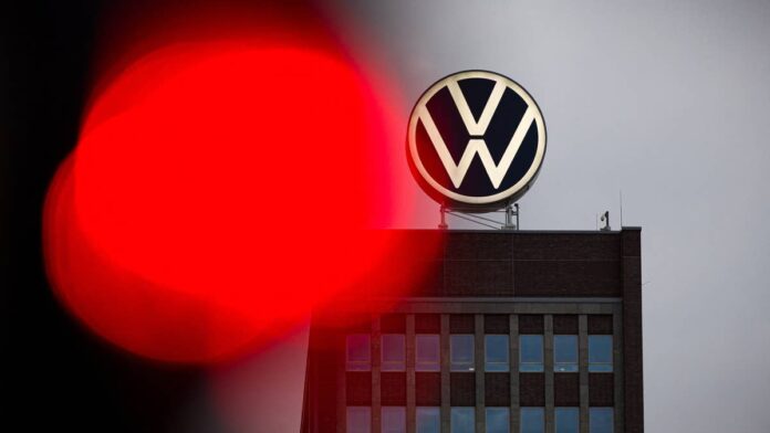 Volkswagen just told investors it will <strong>cut 50,000 more jobs</strong>, and the market cheered.
Shares of Europe’s largest automaker jumped after the announcement, a reaction that tells you a lot about what Wall Street wants from legacy car companies right now.
For investors, a rising stock and a shrinking workforce point in the same direction, and that is worth understanding.
Why Volkswagen stock climbed on the 50,000 job cuts
Volkswagen’s Frankfurt-listed shares <strong>rose more than 8%</strong> on <strong>Thursday</strong>, <strong>September 3</strong>, after its supervisory board approved the plan.
When a company cuts tens of thousands of jobs, its fixed costs fall fast, and investors read lower costs as higher future profit.
The move doubles Volkswagen’s total workforce reduction target to <strong>about 100,000 positions</strong> by <strong>2030</strong>, <strong>roughly 15%</strong> of its global staff, <a href="https://www.bbc.com/news/articles/cx2z0kvy4n4o">BBC</a> reported.
A second reason for the relief was the union support. Volkswagen’s unions, which represent <strong>more than 650,000 workers</strong>, backed the framework, <a href="https://www.businesstimes.com.sg/companies-markets/volkswagen-plans-slash-50000-more-jobs-amid-dire-need-reduce-costs">The Business Times</a> reported.
That deal helped avoid a strike and eased a standoff with <strong>Lower Saxony</strong>, its second-largest shareholder.
The market cheered Volkswagen’s largest restructuring ever, but the recovery is not over.<a href="https://www.gettyimages.com/detail/2292840084">picture alliance / Getty Images</a>
Inside the “Future Plan 2030” restructuring
The job cuts are one piece of a <strong>12-part overhaul</strong> the company calls the <strong>most extensive transformation</strong> in its <strong>89-year history</strong>, <a href="https://www.cnbc.com/2026/09/04/volkswagen-job-cuts-tariffs-china.html">CNBC</a> reported.
Volkswagen plans to <strong>cut its model lineup in half</strong> and <strong>reduce vehicle complexity by about 75%</strong> so that it can focus on higher-margin cars.
It also admitted to major factory overcapacity in Europe and is reviewing the future of four German plants at Emden, Hanover, Zwickau, and Neckarsulm.
Here is what management wants the plan to deliver:
What the “Future Plan 2030” targets
A <strong>9% operating margin by 2030</strong>, up sharply from the <strong>3.8% margin</strong> <a href="https://www.volkswagen-group.com/en/half-yearly-financial-report-and-results-2026-20506">Volkswagen</a> posted in the first half of this year
Annual sales of <strong>about 9 million vehicles</strong>
A <strong>leaner structure</strong> that lets Volkswagen design and ship cars faster
CEO <a href="https://www.volkswagen-group.com/en/executive-bodies-15790">Oliver Blume</a> is betting that fewer models and lower costs can rebuild profitability that has dropped over the past year.
The risks that could stall Volkswagen’s turnaround
Volkswagen’s profit from its China joint ventures is projected to fall to <strong>between 200 million and 600 million euros</strong> this year, down <strong>from 958 million euros</strong> in 2025.
Cheaper, high-tech Chinese electric vehicles from rivals like BYD keep taking market share.
The company also faces <strong>Western import tariffs</strong> and <strong>high German energy and labor costs</strong>. That combination squeezes margins from several directions at once.
Citi analysts noted the deal does not automatically change the competitive pressure in Europe, continued China losses, or raw material costs, <a href="https://www.rte.ie/news/business/2026/0904/1590280-volkswagens-job-cuts/">RTE</a> reported.
How Volkswagen compares to U.S. rivals this year
Volkswagen’s struggles echo across the industry, though performance varies widely by company.
Ford stock is <strong>up about 13%</strong> year to date, and General Motors has gained <strong>roughly 3%</strong>, while Tesla and Rivian have each <strong>fallen about 25%</strong> during the same stretch.
<strong>More Auto Stocks:</strong>
<a href="https://www.thestreet.com/automotive/tesla-cybercab-launch-what-investors-should-know"><strong>Elon Musk’s $30,000 Cybercab is about to face its biggest test</strong></a>
<a href="https://www.thestreet.com/automotive/lucid-air-recall-wall-street-reaction"><strong>EV maker’s biggest ever recall hits 27,000-plus sedans</strong></a>
<a href="https://www.thestreet.com/automotive/rivian-cfo-resigns-ge-vernova-ai"><strong>Top EV executive joins the AI boom. Now what?</strong></a>
That gap shows investors currently favor automakers with lower costs and steadier cash flow, which is the reputation Volkswagen is trying to rebuild.
What Volkswagen investors should watch next
If you hold or are considering Volkswagen stock, a few checkpoints can help you judge whether the turnaround is working.
Track the operating margin each quarter to see if it climbs from 3.8% toward the 9% goal, rather than watching total car sales.
Also, watch the plant negotiations. The company’s management has until <strong>June 2027</strong> to finalize what happens to those four underused German factories, and any union friction could pressure the stock again.
Spreading your risk also helps. Legacy automakers are all moving through a hard transition, so balancing a single auto stock with broader industrial or technology funds can soften the impact if the recovery takes long.
The takeaway is straightforward. Thursday’s jump reflects optimism about cost cuts rather than a finished recovery, and Volkswagen still has a lot to execute before the numbers back up this week’s confidence.
<strong><a href="https://www.thestreet.com/automotive/tesla-just-set-a-date-for-its-riskiest-launch-yet">Related: Tesla just set a date for its riskiest launch yet</a></strong>