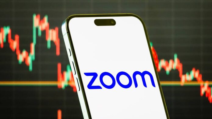 Bank of America is getting bullish on Zoom Communications again as the software company pushes deeper into phone, contact center, and artificial intelligence products after years of post-pandemic normalization.
Zoom Communications (ZM) was reinstated at Buy by BofA analyst Matt Bullock, who set a $130 price objective that implies roughly 24% upside from the $104.71 price used in the firm’s research.
In a note given to TheStreet, Bullock said Zoom’s setup for sustainable growth has become “much more attractive” as enterprise spending improves and newer products begin to carry more of the load.
BofA sees Zoom moving beyond meetings
Zoom became one of the defining software winners of the pandemic, but the reopening economy left the company dealing with contract reductions, a mature meetings market, and growing competition from Microsoft Teams.
That reset is beginning to ease. Zoom reported fiscal first-quarter 2027 <strong><a href="https://investors.zoom.us/node/14381/pdf">revenue</a></strong> of $1.24 billion, up 5.5% from a year earlier, while enterprise revenue grew 7.2%. Constant-currency revenue growth reached 4.6%, continuing a broader acceleration from the company’s post-pandemic lows.
BofA expects Zoom’s newer products to help push growth into the mid-single-digit range. Zoom Phone has surpassed 10 million paid seats, while Contact Center has crossed $100 million in annual recurring revenue, according to the note.
The analyst also expects enterprise net dollar expansion, which improved to 99% in the latest quarter, to climb above 100% as customers add Phone, Contact Center, Workvivo, and AI products.
Microsoft remains the biggest competitive threat. BofA argues the most significant wave of customers consolidating onto Teams has largely played out, leaving Zoom with a more durable base and more opportunities to coexist alongside Microsoft’s platform.
Zoom Communications (ZM) was reinstated at Buy by BofA analyst Matt Bullock, who set a $130 price objective.<a href="https://www.gettyimages.com/detail/news-photo/chongqing-china-in-this-photo-illustration-a-smartphone-news-photo/2230753453?slot=59&adppopup=true">Cheng Xin via Getty Images</a>
Zoom has a multibillion-dollar asset hiding in plain sight
BofA’s bull case also includes an asset investors may not normally associate with Zoom: a sizable investment in Anthropic.
Zoom disclosed in its fiscal first-quarter <strong><a href="https://www.sec.gov/Archives/edgar/data/1585521/000158552126000071/zm-20260430.htm">10-Q</a></strong> that it invested another $46 million in Anthropic preferred stock during the quarter, bringing the carrying value of that position to $1.27 billion as of April 30. The company had $1.88 billion in total strategic investments at quarter-end.
That accounting value may significantly understate what BofA thinks the stake is worth today.
Anthropic raised $65 billion in a Series H <strong><a href="https://www.anthropic.com/news/series-h">financing</a></strong> in May at a $965 billion post-money valuation, up sharply from the valuation used to determine Zoom’s disclosed carrying value.
More Tech Stocks
<strong><a href="https://www.thestreet.com/investing/stocks/cathie-wood-sells-palantir-pltr-11-6-million-of-surging-tech-stock">Cathie Wood sells $11.6 million of surging tech stock</a></strong>
<strong><a href="https://www.thestreet.com/investing/stocks/stanley-druckenmiller-alphabet-stock-q2-bet-googl">Stanley Druckenmiller builds $120 million bet on major tech stock</a></strong>
<strong><a href="https://www.thestreet.com/investing/stocks/thiel-macro-amazon-stock">Peter Thiel invests $118 million in surging big tech stock</a></strong>
Using that valuation and adjusting for dilution, BofA estimates Zoom owns roughly 0.311% of Anthropic, putting the stake’s estimated value near $3 billion.
BofA incorporates that estimate directly into its $130 price target. The firm values Zoom’s core communications business using a 14.7 times calendar-year 2027 enterprise value-to-free-cash-flow multiple, then adds the estimated value of the Anthropic stake.
The bank estimates Zoom trades around 13 times 2027 EV/free cash flow before accounting for Anthropic. Stripping out the estimated $3 billion value of the investment lowers the implied valuation on the core business to about 11 times, strengthening BofA’s argument that the shares remain inexpensive.
Zoom still has risks to work through
The bull case depends on Zoom proving its newer products can offset pressure in its mature meetings business.
BofA highlighted Microsoft bundling, enterprise down-sells, online customer churn, and slower-than-expected adoption of new products as major risks. Contact Center also faces entrenched competitors, while Zoom still has to prove that growing AI usage can translate into meaningful paid revenue.
Zoom has financial room to pursue that strategy. The company ended April with roughly $7.7 billion in cash, cash equivalents, and marketable securities, and generated $521.6 million in operating cash flow during the quarter.
BofA sees improving operating trends as enough to support its Buy rating after Zoom spent years working through its post-pandemic reset. The estimated value of its Anthropic investment gives the bull case another catalyst investors may have overlooked.
<strong><a href="https://www.thestreet.com/investing/louis-navellier-sets-eye-opening-nvidia-stock-price-target-for-rest-of-this-year">Related: Louis Navellier sets eye-opening Nvidia stock price target for rest of this year</a></strong>